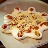 Stella, impasto astronave con fichi,&nbsp;gorgonzola, noci, speck e miele di acacia&nbsp;pronto per il forno di Beniamino Bilali, collaboratore del titolare&nbsp;Matteo Aloe di&nbsp;Berber&eacute; light pizza & food a Castel Maggiore (Bo). Assieme a Franco Pepe, Giuseppe Giordano, Massimo Gatti, Roberto Pongolini, Corrado Assenza, Enzo Coccia, l'inglese Jon Pollard e Simone Padoan, Bilali&nbsp;&egrave; parte dei magnifici 9 di Identit&agrave; di pizza, luned&igrave; 6 febbraio, sala blu 2
