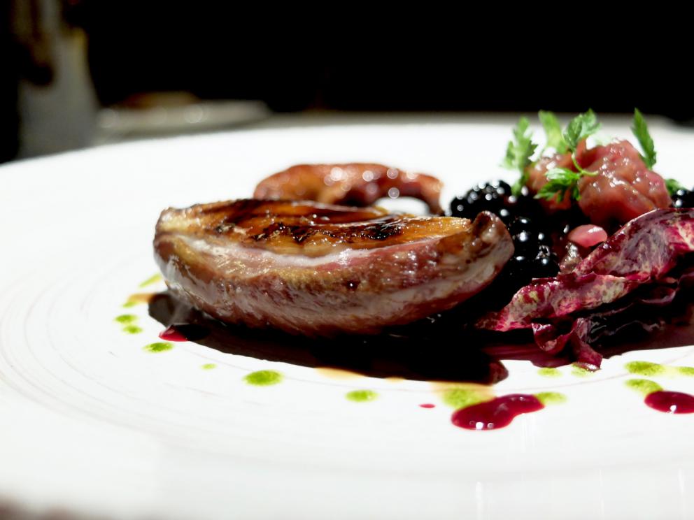 PhotogalleryOur dinner at Stube Gourmet, depicted by Tanio Liotta. We start with Duck breast, pumpkin mostarda, sesame wafer and tarragon 
Savoury cone with veal steak tartare, marjoram and salmon roe
A reconstructed tomato: mousse of tomato, vegetal carbon, mousse of almonds, basil gel
Fake peanut with foie gras, cocoa butter, horn of plenty 
Excellent bread and butter
Giardino di verdure, terra di mandorla, formaggio caprino: marinated, dehydrated, raw or cooked vegetables, with powdered beetroots, almonds and goat cheese
Codfish pearls, dashi broth, ginger, coriander. These gnocchetti look like they&rsquo;re made with potatoes but it&rsquo;s cod and flour
Spaghetti with spinach chlorophyll, daikon, mozzarella, herring roe. The mozzarella is in fact mozzarella water, daikon is in the shape of gel, plus nasturtium sprouts
Carnaroli rice, tarragon, cucumber, currants
Duck foie gras escalope, orange pan brioche, granny smith gel, candied watermelon
Pigeon in three styles of cooking. In this case leg confit with blackberries and hazelnut sauce
Pigeon tartare on radicchio, compote of onions and blackberries
