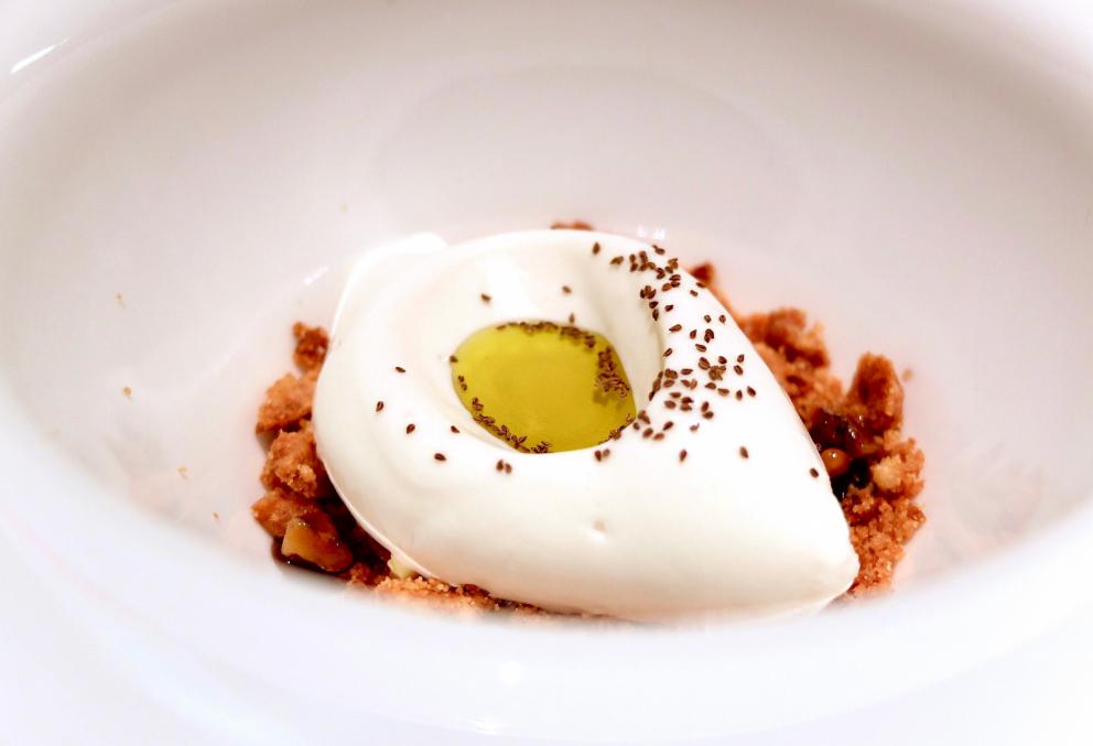 Photogallery






A new Lorenzo Cogo at the new El Coq, since July 2016 in the heart of Vicenza









At the entrance, the Carlton library by Ettore Sottsass, a great designer, founder of the  Memphis Group. In fact, it is entirely made in sugar, the work of artist Marco Chiurato

 









We get to the first floor: the perspective at the entrance recalls the depth of Palladio’s works









The elegant dining room









Precious cutlery by Giò Ponti for Sambonet. Everything is studied: the colour of the tablecloth is inspired by the roof of the Basilica Palladiana









The view from the dining room...









...and from the kitchen









Let’s start: Cherry tomato, angustura, vegetable jus. All the photos of the dishes are by Tanio Liotta









Beetroot macaroons with radicchio and Béarnaise sauce with mint 









Choux pastry with peanut cream and dried bacon 









Doughnut with goat cheese and curry cream: the last appetizer









Fondale marino, scalogno, salmone e salicornia: the shallot is chargrilled, there’s peppermint mousse, powdered salmon, and granita made with sea asparagus and orange bitter









Amberjack belly, rosola and peas: an improvisation based on what was available from the market. Fish and peas are chargrilled, then there’s a vinaigrette of pods and rosole, poppies









Chargrilled calamari, babaganush, bergamot and teriaki: the grill, once again. Cogo learnt its perfect use from Basque master Victor Arguinzoniz of Asador Etxebarri

 









Bosaga roe, yellow pepper, sake and ice camomile. Masterful what with complexity and elegance. Bosaga is a fish typical of Chioggia









Jerusalem artichoke "risotto", tuna bottarga and horseradish. There are many fake risottos available, such as the one with celeriac by Yoji Tokuyoshi and Salvatore Tassa or the vegetable one by Pedro Subijana. This is really perfect, with cream of Parmigiano and artichoke petals









Spaghetti with garlic and oil, hazelnut milk and seafood, with caviar of iced extra virgin olive oil and sea fennel. Beautiful, masterful and quite good too









Gargato, squid liver, mousse of buffalo milk mozzarella and ginseng. Gargato is a small maccherone. A delicious dish









Iceberg is an interlude: the salad is soaked in amaro Alpestre, a herb spirit. Then powdered cassis









Veal liver, wild asparagus, San Giuseppe, a typical spirit from Vicenza. Plus hop gel, cranberries and bran. Perfect harmony









Sweetbreads, radicchio and yogurt with herbs: the sweetbreads are cooked in hay, the radicchio is grilled. There’s balance, flavour, structure, elegance in every dish. Enrico Bartolini comes to mind









Piglet pluma, tofu, black garlic, rocket salad cream, turnip tops and ravette, that is to say wild baby radicchio. «There’s a man who gets them for me at over 1,600 metres, on the mountains above Marano Vicentino. He digs them out of the snow»






