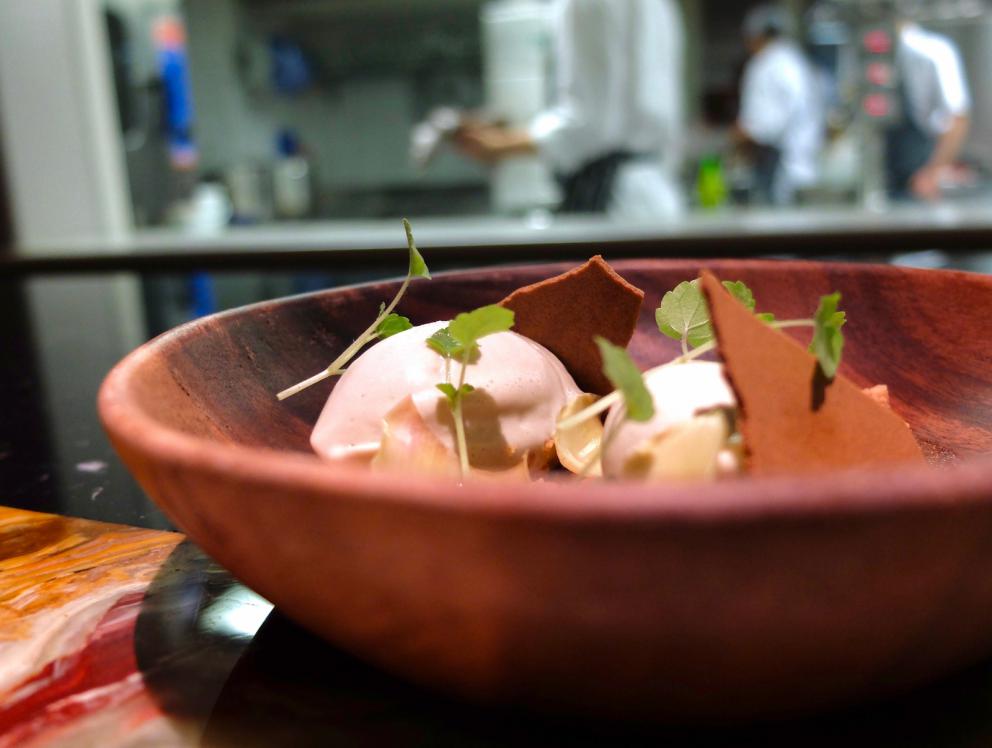 Photogallery






A new Lorenzo Cogo at the new El Coq, since July 2016 in the heart of Vicenza









At the entrance, the Carlton library by Ettore Sottsass, a great designer, founder of the  Memphis Group. In fact, it is entirely made in sugar, the work of artist Marco Chiurato

 









We get to the first floor: the perspective at the entrance recalls the depth of Palladio’s works









The elegant dining room









Precious cutlery by Giò Ponti for Sambonet. Everything is studied: the colour of the tablecloth is inspired by the roof of the Basilica Palladiana









The view from the dining room...









...and from the kitchen









Let’s start: Cherry tomato, angustura, vegetable jus. All the photos of the dishes are by Tanio Liotta









Beetroot macaroons with radicchio and Béarnaise sauce with mint 









Choux pastry with peanut cream and dried bacon 









Doughnut with goat cheese and curry cream: the last appetizer









Fondale marino, scalogno, salmone e salicornia: the shallot is chargrilled, there’s peppermint mousse, powdered salmon, and granita made with sea asparagus and orange bitter









Amberjack belly, rosola and peas: an improvisation based on what was available from the market. Fish and peas are chargrilled, then there’s a vinaigrette of pods and rosole, poppies









Chargrilled calamari, babaganush, bergamot and teriaki: the grill, once again. Cogo learnt its perfect use from Basque master Victor Arguinzoniz of Asador Etxebarri

 









Bosaga roe, yellow pepper, sake and ice camomile. Masterful what with complexity and elegance. Bosaga is a fish typical of Chioggia









Jerusalem artichoke "risotto", tuna bottarga and horseradish. There are many fake risottos available, such as the one with celeriac by Yoji Tokuyoshi and Salvatore Tassa or the vegetable one by Pedro Subijana. This is really perfect, with cream of Parmigiano and artichoke petals









Spaghetti with garlic and oil, hazelnut milk and seafood, with caviar of iced extra virgin olive oil and sea fennel. Beautiful, masterful and quite good too









Gargato, squid liver, mousse of buffalo milk mozzarella and ginseng. Gargato is a small maccherone. A delicious dish









Iceberg is an interlude: the salad is soaked in amaro Alpestre, a herb spirit. Then powdered cassis









Veal liver, wild asparagus, San Giuseppe, a typical spirit from Vicenza. Plus hop gel, cranberries and bran. Perfect harmony









Sweetbreads, radicchio and yogurt with herbs: the sweetbreads are cooked in hay, the radicchio is grilled. There’s balance, flavour, structure, elegance in every dish. Enrico Bartolini comes to mind









Piglet pluma, tofu, black garlic, rocket salad cream, turnip tops and ravette, that is to say wild baby radicchio. «There’s a man who gets them for me at over 1,600 metres, on the mountains above Marano Vicentino. He digs them out of the snow»









Pane e olio, that is to say bread gelato with extra virgin olive oil, celery seeds and candied walnut. «It’s my homage to Marano Vicentino. I created it the day I said goodbye». Cogo opened in Vicenza on the 19th of July 2016, the day of his 30th birthday






