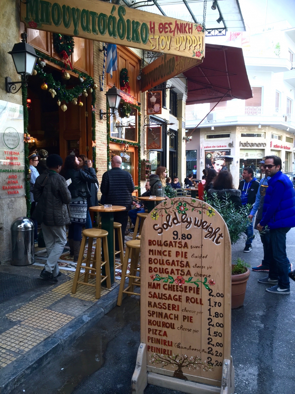 Photogallery






Breakfast with koulouri: you can find it all over town, we've chosen a kiosk between Korai and Stadiou, a stone's throw away from the university and not far from Psiri, the market area








Second stop, at Krinos (Aiolou 87): since 1922 it is the temple of loukoumades, pancakes fried in sesame oil and covered in honey and chopped almonds (loukuma is a word of Arab origins meaning nibble). A 6-piece portion costs 3.60 euros








The meat and fish market at Varvakios Agora (Athinas 42, a short walk from Krinos)








Come and grab some lamb!








Meat and fish market








Seafood delicacies. It's important to visit the fish market early in the morning because the best products are soon sold to restaurants













Walking around Psiri, Athens food corner








A pedlar selling salepi, an Ottoman drink made with dried orchid tubers








Slow food








Halva, a popular cake from India to the East of the Mediterranean Sea, based on tahina, a sesame paste. The word halva comes from the ancient Jewish where it meant 