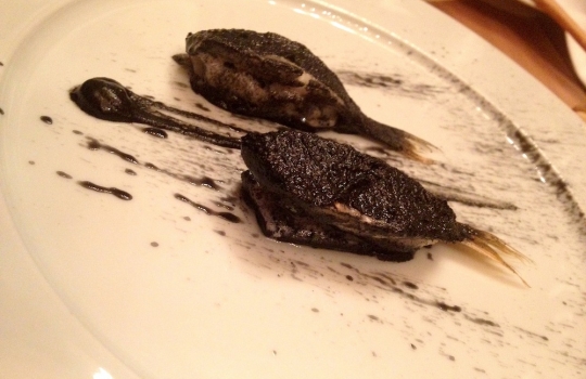 Photogallery






 
Modena’s colonnades, 186 thousand inhabitants and 3 restaurants with at least one Michelin star: Hostaria del Mare (1), Erba del Re (1) and Osteria Francescana (3 stars), our destination
 








Yellow and red tones prevail








The city still bears the signs of the May 2012 earthquake. On May 4th 2013, the day of our visit, a 3.8 magnitude earthquake was registered













By chance, Giuseppe Palmieri, maître and sommelier, appears from the grey door








Palmieri, 38, born in Matera. His first service in Francescana was on September 12th 2000








The old entrance to the restaurant, at number 24 in Via della Stella - as on the opening in 1995. It changed in September 2012: today you enter from number 22. Funnily enough, Google Maps is still set on the old entrance








The present entrance doors








Let’s start








After the latest renovations, the transit areas inside the Osteria appear as a contemporary art gallery








Mario Schifano’s world map








"Tourists", Maurizio Cattelan’s famous pigeons








Underneath the pigeons, Gavin Turk’s “Trashbag”








Three rooms, 12 tables, between 20 to 35 guests. 40% guests are Italian








Every table is illuminated by Davide Groppi’s Sampei lamp: if tables are moved, light follows








Francescana receives 150 reservations every day. But it also suffers from clients not showing up: on average, one table every week is booked but then guests don’t come








Right behind the kitchen, there’s the prêt-à-porter cellar








"In the central cellar, we only keep great vintages and larger bottles of what we consider to be great wines", Beppe Palmieri explains








1,600 wines are listed at Osteria Francescana, with a deep wine list which includes different vintages of the same wine








"A true celebration of wine "








The Ferrari coat, hanging in the cellar: Maranello is only 17 km away from Modena








Jean Todt, Michael Schumacher, Fernando Alonso: Ferrari’s “prancing horse” is at home in Via Stella








Gabrio Bini’s wines, from Pantelleria, a real fetish for Palmieri













Hanging from the ceiling, a nice selection of cured meats from Emilia








Bread made with mother yeast, the premise to a journey which will alternate great classics with very contemporary dishes








Massimo Bottura. Fifty years old last September, he is chef since 1986, the year of Trattoria del Campazzo in Nonantola. His first masters: Lidia Cristoni and Georges Cogny








He’s glowing: a few days ago his restaurant climbed, for the first time, onto the podium of the World's 50Best, a prize that is acquiring an increasing weight and authority. "The thing that makes me the happiest", he says, "is not so much the third place, but the fact that we’ve been in the highest positions for a few years now". True: 13th in 2009, 6th in 2010, 4th in 2011, 5th in 2012, 3rd in 2013








The now famous grey New Balance 993, a real emblem for the chef, friend of Jason Weis, president of the company in Massachusetts. The insole, however, is local: "In Emilia the sector is state-of-the-art", he says








"Are we ready?"








Almond granita with capers, bergamot and coffee cream 
Bottura and Palmieri’s journey across Italy starts from the bottom. And sails off from the Sicilian inland, with a classic granita which in Modena crumbles Adria-style, the wall that divides sweet from savoury, using the picklock of bitterness: Pantelleria capers, wild oregano but also bergamot, a coffee concentrate and vanilla scented salt. To pair with the first part of the meal, Sorriso di Cielo malvasia dei colli piacentini








Mediterranean Macaroon 
Next to the granita, two peculiar macaroons: the first is made with minced anchovies and sardines, the second with oysters and seaweeds. This is a classic scheme in Bottura’scuisine: his ironic turning the order of the dishes, from starter to dessert, upside down, and using popular raw materials instead of ingredients that are emblematic of élite cuisine. «While feet are sinking in the ground, the head is free to move everywhere», is one of his most famous quotes








Tempura of freshwater aulla with carpione ice-cream
Carpione ice-cream on a tempura of freshwater aulla – these fish are similar and slightly bigger than whitebait. The tempura is made by quickly placing the cold batter in boiling oil








Bread and croissants








Grissini








Baccalà Mare Nostrum 
We move up the Tyrrhenian sea to find this salted codfish cooked at low temperature and then seasoned with a touch of Naples and the Amalfi coast, that is to say with an emulsion made with hot oil with tomato vegetal liquid, olives, the zest of Sorrento’s super lemons and some anchovy colatura. These aromas crack with the scented bread on top








40 year old Denis Bretta explains the dishes as if from a book. Once at Restaurant Fini in Modena, for the past year and a half he’s been the manager responsible for the service in the restaurant. But don’t ask Palmieri to explain his role, as he’s abolished all hierarchies: "In our restaurant there are no commis or chef de rang. At a time when titles are so abused, I prefer for us to be all colleagues. All waiters."





