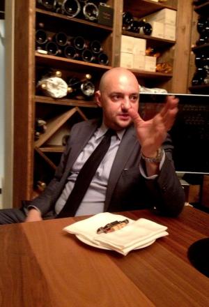 Photogallery






 
Modena’s colonnades, 186 thousand inhabitants and 3 restaurants with at least one Michelin star: Hostaria del Mare (1), Erba del Re (1) and Osteria Francescana (3 stars), our destination
 








Yellow and red tones prevail








The city still bears the signs of the May 2012 earthquake. On May 4th 2013, the day of our visit, a 3.8 magnitude earthquake was registered













By chance, Giuseppe Palmieri, maître and sommelier, appears from the grey door








Palmieri, 38, born in Matera. His first service in Francescana was on September 12th 2000








The old entrance to the restaurant, at number 24 in Via della Stella - as on the opening in 1995. It changed in September 2012: today you enter from number 22. Funnily enough, Google Maps is still set on the old entrance








The present entrance doors








Let’s start








After the latest renovations, the transit areas inside the Osteria appear as a contemporary art gallery








Mario Schifano’s world map








"Tourists", Maurizio Cattelan’s famous pigeons








Underneath the pigeons, Gavin Turk’s “Trashbag”








Three rooms, 12 tables, between 20 to 35 guests. 40% guests are Italian








Every table is illuminated by Davide Groppi’s Sampei lamp: if tables are moved, light follows








Francescana receives 150 reservations every day. But it also suffers from clients not showing up: on average, one table every week is booked but then guests don’t come








Right behind the kitchen, there’s the prêt-à-porter cellar








"In the central cellar, we only keep great vintages and larger bottles of what we consider to be great wines", Beppe Palmieri explains








1,600 wines are listed at Osteria Francescana, with a deep wine list which includes different vintages of the same wine








"A true celebration of wine "








The Ferrari coat, hanging in the cellar: Maranello is only 17 km away from Modena








Jean Todt, Michael Schumacher, Fernando Alonso: Ferrari’s “prancing horse” is at home in Via Stella








Gabrio Bini’s wines, from Pantelleria, a real fetish for Palmieri













Hanging from the ceiling, a nice selection of cured meats from Emilia








Bread made with mother yeast, the premise to a journey which will alternate great classics with very contemporary dishes








Massimo Bottura. Fifty years old last September, he is chef since 1986, the year of Trattoria del Campazzo in Nonantola. His first masters: Lidia Cristoni and Georges Cogny








He’s glowing: a few days ago his restaurant climbed, for the first time, onto the podium of the World's 50Best, a prize that is acquiring an increasing weight and authority. "The thing that makes me the happiest", he says, "is not so much the third place, but the fact that we’ve been in the highest positions for a few years now". True: 13th in 2009, 6th in 2010, 4th in 2011, 5th in 2012, 3rd in 2013








The now famous grey New Balance 993, a real emblem for the chef, friend of Jason Weis, president of the company in Massachusetts. The insole, however, is local: "In Emilia the sector is state-of-the-art", he says








"Are we ready?"








Almond granita with capers, bergamot and coffee cream 
Bottura and Palmieri’s journey across Italy starts from the bottom. And sails off from the Sicilian inland, with a classic granita which in Modena crumbles Adria-style, the wall that divides sweet from savoury, using the picklock of bitterness: Pantelleria capers, wild oregano but also bergamot, a coffee concentrate and vanilla scented salt. To pair with the first part of the meal, Sorriso di Cielo malvasia dei colli piacentini








Mediterranean Macaroon 
Next to the granita, two peculiar macaroons: the first is made with minced anchovies and sardines, the second with oysters and seaweeds. This is a classic scheme in Bottura’scuisine: his ironic turning the order of the dishes, from starter to dessert, upside down, and using popular raw materials instead of ingredients that are emblematic of élite cuisine. «While feet are sinking in the ground, the head is free to move everywhere», is one of his most famous quotes








Tempura of freshwater aulla with carpione ice-cream
Carpione ice-cream on a tempura of freshwater aulla – these fish are similar and slightly bigger than whitebait. The tempura is made by quickly placing the cold batter in boiling oil








Bread and croissants








Grissini








Baccalà Mare Nostrum 
We move up the Tyrrhenian sea to find this salted codfish cooked at low temperature and then seasoned with a touch of Naples and the Amalfi coast, that is to say with an emulsion made with hot oil with tomato vegetal liquid, olives, the zest of Sorrento’s super lemons and some anchovy colatura. These aromas crack with the scented bread on top








40 year old Denis Bretta explains the dishes as if from a book. Once at Restaurant Fini in Modena, for the past year and a half he’s been the manager responsible for the service in the restaurant. But don’t ask Palmieri to explain his role, as he’s abolished all hierarchies: "In our restaurant there are no commis or chef de rang. At a time when titles are so abused, I prefer for us to be all colleagues. All waiters."








How to burn sardines in three days 
Another journey, another horizon, the Adriatic Sea between Romagna and Ancona. A new camouflaged expression: these are not sardines (and they aren’t burnt either) but they are small sea-rock mullet, marinated for 3 days, then seared on one side on a grill, and filled like a sandwich with some (very sweet) scampi cream, and covered with vegetable ashes, aromatic herbs and lemon zest. “I wanted to make fun of the Marche-Romagna habit of grilling everything”, the chef says, “with lemon, garlic and parsley always added later to fix everything”









Rice, between fresh and sea water 
Recalling the Po estuary with freshwater and brackish sensations. The freshwater flavours cover the surface of the oyster which prevails on the river bed. And in the end, catfish, carp, vegetable chlorophyll and carpione win once again








 
A journey to Modena: Adriatic eel, polenta, Campanine apple jelly and saba
Another fluvial odyssey, presented for the first time at Identità Milano in 2011. The Adriatic eel travels across Veneto (with the polenta cream), Mantua (the Campanine apple jelly), the countryside of Modena (with the Saba lacquering, that is to say the mother of Aceto Balsamico) and stops in the centre of Modena (blackened powdered onion, a mimesis of the town’s canals)
 








Normandy
That is to say pre-salè lamb (hanging for 20 days) with an emulsion of oyster water, fresh seaweeds and caviar. On top, a green apple granita that recalls cider. “This is our tribute to Normandy”, Bretta says, “in Modena there are no enchanted beaches or breath-taking mountain tops. From Via Stella you can’t even see the Torre Ghirlandina. What guides us is the persistant strength of ideas, woven into the culture and into memories”








Giovanni Boroni’s Genziana from Trentino. A brilliant idea by Palmieri that acts as a bridge between the two dishes, Normandy (previous picture) and Think Green (next one). This distillate plays an immediate contrast with the sea-character of the first dish: "To me, harmony is what is left after a confrontation", B.P. says. And the confrontation is followed by the thought that spurs from the following match: water is added to the Genziana and the palate surprisingly longs to gulp it all. This is the perfect vehicle for the aromas of the genziana and "gives length" to the minerality of the wild herbs. "This serves to recall water, our true source of richness". Brilliant








Think Green
Vegetal chlorophyll, asparagus tops, pea cream, mushrooms, truffle, flowers, aromatic herbs and Parmigiano Reggiano curd. The idea of this dish came after observing the biological cycle of grazing cows, 4 seasons that sum up all of life. “This is what the cow eats, and what it returns to us, thanks to an extraordinary milk”, Bottura adds








Five ages of Parmigiano Reggiano 
A great classic from 1996, "when the textures in fact were 3", Palmieri points out. Today they are 5: 4 month ageing cream, 30 month demi-soufflè, 36 month mousse, 40 month crispy wafer, on top, “air” of 50 month Parmesan. (photo by Le Saucier)








A compression of pasta and beans 
Another great classic, this is a journey across Bottura’s experiences in the kitchen: Creme royal with pork rind, beans and foie gras (French tradition), rosemary air (the Spanish vanguard) and Parmesan crust (the Emilian essence) used instead of pasta. “This is a dish based on evolution, not revolution. I compressed my grandmother between Alain Ducasse and Ferran Adrià”








Snails under the grapevines 
Snails, aromatic chlorophyll on a bed of wild vegetables and herbs, with mushrooms, truffle and bulbs. After the cow’s life cycle, here comes that of the snail. "Once again, we’re chewing the territory: the best snails slither in the vineyards, among mineral, sapid and acid aromas"








A Frenchman’s dream of making pasta like an Italian 
Or, Ravioli with leeks, foie gras and truffle. We covered this in detail in Identità di Pasta issue number 27








Damijan Podversic’s Ribolla Gialla, a great wine by a wine producer from Gorizia inspired by Josko Gravner. It will support the following dish, without concealing it








A sharp knife is only served now. Another sign of the “allergy” to lengthy chewing that characterises most of contemporary high cuisine








Pigeon hunt 
And over to Bretta: "This is served in a balsamic sauce made with beetroots, which recalls blood. The salad is made with fake leaves, made by cutting out some tubers using some small stamps. These are then compressed in a vacuum with different types of vinegar. The horseradish is grated a few seconds before service, to give some velocity to the pigeon". Irony wins, since "pigeons are not hunted". The bird supplier is Franco Cazzamali from Cremona








Before the dessert, a trip to the restroom: vegetal notes prevail here too








A visit to the kitchen: capon stock








The chef watches over everything, even on the loud music wired wireless from the ceiling. When we get inside, Rod Stewart is screaming "Do you think I'm sexy?"








Meanwhile, the sauces are prepared for the evening service. There’s no break between lunch and dinner. "People sometimes leave at 5 pm because they come here to enjoy the experience of a lifetime", Palmieri reveals, "We work non-stop and every year is worse (or better, that is to say). Don’t ask me anything after midnight, though, because I can’t think straight"








Between dining room and kitchen, today 27 people work at Osteria Francescana. Many of them are interns: "Had I been offered an internship with Ducasse, at the time”, Bottura says, "I would have paid myself". In fact, he really took an internship at the Louis XV in Monte Carlo, in 1992








Leaves 
The journey takes us amidst the forests beds in Umbria: the real leaves change according to the season (black cabbage in winter, red and green basil in spring), they are caramelised and then worked with some chestnut and hazelnut paste, with a vin brulée reduction, chocolate and citrus fruits concentrate...








Magnum of Foie gras (before)
A foie gras terrine, vacuum cooked, covered with powdered toasted hazelnuts and chopped toasted almonds, finished with some apple Balsamic Vinegar. This is possibly Massimo Bottura’s most famous (and copied) dish. Alessandra Meldolesi, in her book "Sei. Autirotratto della cucina italiana d'avanguardia" she writes: "It’s a trompe-l’oeil starter in which a mould unmistakably used in the food industry, encloses the secret of the most exclusive delicacies, foie gras and Aceto Balsamico Tradizionale. This is snack versus high cuisine, dessert versus starter, entremets versus carne: the triple antiphrasis manages to get a smile"








Magnum of Foie Gras (after)
Ehm








Oops, a broken lemon tart 
A lemon tart with lemon zabaglione, lemongrass ice-cream, lemon confit, capers and bergamot (with the latter, we go back to where we had started from). This is the last dish of a masterly journey








Sous chef
Here are the staff. We start with Yoji Tokuyoshi, 35, from Japan, for 8 years at Osteria Francescana. He’s just back from the Postrivoro for Slow Fish








Managing orders
Takahiko Kondo, from Japan








Starters
Davide Di Fabio, 27 from Abruzzo








First courses
Michele Castelli, 28, Matera, in Modena since 5 years ago








Main courses
Riccardo Forapani, 27, from Cavezzo (Modena) at Osteria Francescana for the past 5 years and a half








Pastry Making
To the right, pastry-chef Alberto Buratti, 26 from Legnano (Milano), ex Antica Osteria del Ponte with Ezio Santin. With him, Matteo Conterio, from Como, 20 years old, Francescana since last month








Bread making
Bernardo Paladini, 24, from Rome, bread and pasta








Stagista
Klaus Pahl, 26, Brazilian from Sao Paolo, with a previous experience at D.O.M.








Stagista
Franco Liberali, 19, Pescara, second courses








Stagista
Lorenzo Menegatti, 19, from Torino, first courses








Antipasti
Francesco Vincenzi, 21, from Formiglia (Modena)








30 year old twins, Andrea and Luca Garelli, have been working in Francescana for 5 years (I only realised in the end that the guys where two, not one)








In sala
Monica Giordano, 31 years old, from Bologna








Pino Cesario, from Torre del Greco (Naples), arrived at Francescana two weeks ago ("Today even finding a job on the Amalfi Coast is difficult ")








Antonia Guerra, kitchen hand








Back to the table for the petits fours








And a great coffee signed by Leonardo Lelli








Average prices: starters 45, first courses 45, main courses 60, desserts 25 euros. 
Tasting menu: 110 euros (Traditions), 150 euros (Classics), 180 euros (Sensations, seasonal plates from the experimental kitchen).
 The complete menu in pdf








Before returning to see the stars...





