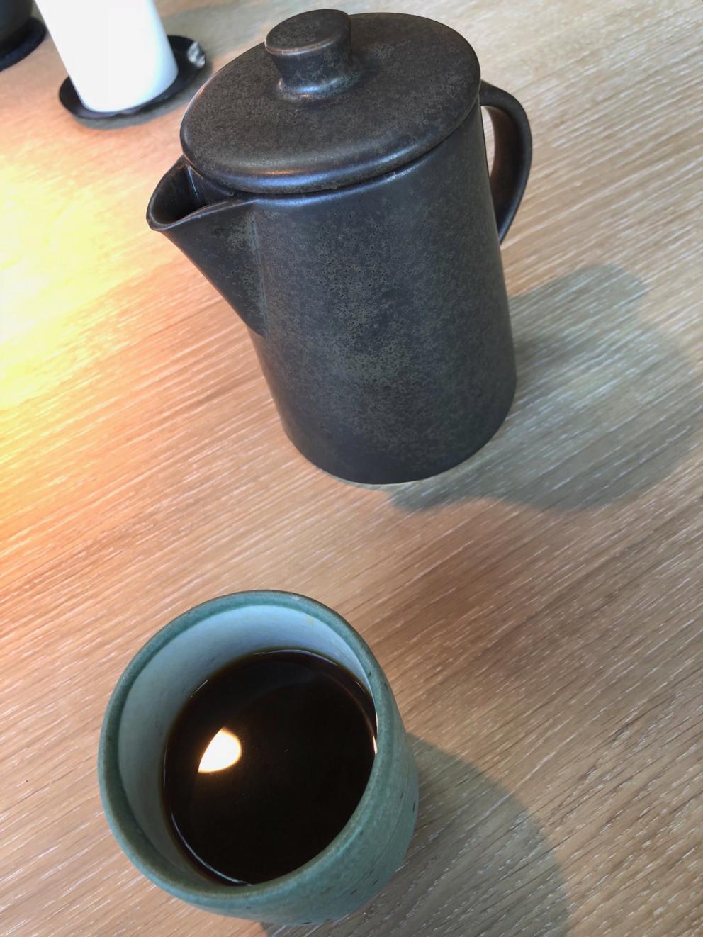 Photogallery






Noma 2.0 is in Christianshavn, the same neighbourhood as the first Noma. They’re 1.5 km apart, a 15 minutes’ walk. This picture shows the distance: to the right, there’s the warehouse of the old location (in Strandgade 93), to the left the smokestacks of Amager Bakke, the futuristic incinerator below which stands the new Noma (in Refshalevej 96)









Weather permitting, you can have a peaceful walk between the previous Noma to today’s Noma 









The new Noma is on an isthmus surrounded by canals. In the future they also want to reclaim some small parts for hydroponic farming









Bucolic scene with incinerator









Bikes left outside Noma. It’s the favourite means of transport among employees and interns









The long path taking you to the restaurant. The fence on the left shows how works are still in progress









On the two sides of the path there are the two new sections of the "Noma village", each with its specialty: grill, hot dishes, snacks, fermentations... In one month’s time, behind the fence we’ll have greenhouses, the test kitchen and the bread making area









To the left, before arriving at the restaurant, the future test kitchen. This will be run by Danish Mette Søberg with Riccardo Canella. "My first challenge?", reveals the latter, for a long time sous chef here, "is to work on the extraction of essential oils" 









The future Test Kitchen









The temporary gangway to the restaurant









Looking from the door to the restaurant, there’s a lake and the smokestacks puffing vapour from the Amager Bakke incinerator. It’s a futuristic project, both in terms of sustainability and architecture. It’s also known as Amager Slope or Copenhill, and its author is starchitect Bjarke Ingels, the same who designed the new Noma. Gradually opened in 2017, it transforms waste into electricity. The goal is to donate electricity to 62500 houses and hot water to 160000. It’s part of an ambitious project to transform Copenhagen into the first city in the world in terms of zero carbon dioxide emissions by 2025. By autumn this year, Amager Slope should open its ski slope, a climbing wall and a hiking track. You’ll be able to slalom on top of the incinerator









The windows from the dining room









Work is still in progress (photo taken on Thursday 22nd February 2018)









Traces of the old building, with barbwire. During WWII, they built bombs here









A view of the dining room at night (photo from Instagram/James Spreadbury)









The entrance to the restaurant









The usual ritual: a welcome from the entire staff, led by Rene Redzepi 









Behind the entrance, there are formaldehyde tanks with creatures from the abyss, shaped as in Damien Hirst’s works. The first image once you’re inside is to reproduce a Scandinavian village









The service kitchen is larger, more spacious and a completely open view from the dining room: "It’s the heart of our Scandinavian village", says Canella. There are 30 cooks working here now. 10 more, compared to the previous Noma









Large skylights above the cooks









There are currently more than 100 people working at Noma, of whom 63 are cooks - 26 employed, and 37 as interns









There’s fire in the kitchen, for the first time









On average, the dining room can host 40 people. "However", complains Redzepi, "there’s always someone who turns up with more people than the ones booked"









While the dining room is set, the outside space still need to be defined









The staff made the dining room decorations. There are no overly expensive designer objects









Dried fish









Seaweeds hanging from the ceiling









Dried octopus heads preserved in salt (with a balloon inside)














Bjarke Ingels and Redzepi’s plan included the wish to recreate a Danish farm









The luminous private dining room









The counter in the dining room. They drew the beams from the canals around the restaurant














The mise en place, bare and strictly without tablecloths









Water jug, candle, flower vase









A warm cloth, to begin with









Australian James Spreadbury, restaurant manager and partner at Noma









Welcome drink: Champagne extra brut Blanc d'Argile from Domaine Vouette et Sorbée









Sea Snail broth. The welcome dish at Noma is, as usual, a hot “soup”









Stefano Ferrano, from Torino, presents the following dish. There’s always a large Italian colony at Noma









Venus clams. Molluscs from Limfjord (Denmark) mixed with decorative clams, typical of Noma. Beside them, shells with blackcurrant oil and “Danish curry”, made with toasted coriander seeds, fennel and fennel seeds









The lid above the following dish. The mussels are not edible









Best of the mussel. Mussels open in a pan with water of fermented barley. «We recreate the mussel», says Canella, «using just the flaps, the best part». The paste is made with scraps from the mussel, cooked in smoked butter









The next dish is conceived and served by Riccardo Canella, the Paduan sous chef who conquered Redzepi, here with dining room intern Feline Hansen









Dried fruits and shrimps. In this case, the heads are not a decoration, but you must suck them –best not eat them because of the bones: they’re filled with a lovely prawn cream. The small crustaceans are still alive when they arrive on a ship straight from the Norwegian fjords









Inside, under the prawn broth skin, there’s fruits and vegetable preserved from the previous summer with raw prawns and gooseberry sauce with blackcurrant oil









How about beverages? There are three options, as usual: wine pairing (6 glasses plus a beer plus sake, 150 euros), juice pairing (juices and extracts, 110 euros) or a choice from the list. They recommend Champagne Chut... Libre from Val'Frison pour Dominique Derain, 50% Pinot Noir, 50% Chardonnay created by a couple who met at the old Noma. Well bodied, it will be a good match throughout the meal









As usual, the wine list starts with Champagne: the cheapest is 1400 crowns (190 euros)









White wines begin with labels from cold climates: first Austria, increasingly popular for its natural wines, then Germany, then all the others









How about Italy? Few names, among the white wines, from North and South









A dozen red/orange wines









Sea star, that is to say Cured trout roe and eggs, the emblem dish of this new era. They recommend moving the teaspoon from the heart to the edges of the tentacles. Aesthetics win over taste









Jellyfish. The jellyfish gel in the middle is in fact a clarified broth of calamari and recalls the texture of jellyfish. "We tried to cook jellyfish in 300 different ways but none was convincing so far". All around, pickled seaweed. The gel is almost tasteless, it serves to clean the palate after the pickles









Rene Redzepi himself presents the content of the first Seafood platter.









French style service with a small plate below for the empty shells









It’s made of two (per two) pieces: queen clam and mahogany clam









The Queen Clam is a very small variety of Norwegian scallop, seasoned with a vegetal reduction made with cucumber and peas miso. The red tip is the coral. "You should eat it using the top shell ", recommends Redzepi









The Mahogany clam is a centennial clam from the North Sea, very popular in Denmark and Iceland. «You can tell the age by the number of rings, like with trees», says Redzepi, «In 2007 they found one that was 450 years old. We’ve had it in the menu for a decade or so». The razor clam shell serves as teaspoon









Inside, there’s obviously not just a bare Mahogany. «We open it when the client arrives», says Canella, «remove the entrails and then slice it so as to preserve its firm texture». It’s seasoned with stir-fried gooseberry, capers of blackcurrants and blackcurrant sprouts preserved in vinegar. The sauce is made with mussel water









A note on the chairs: they’re more minimalistic. They’re no longer covered in sheepskin or leather from other Danish animals, in the style of Noma 1.0. The most significant element is the napkin: if you go to the toilet, they no longer replace it with a new one. There’s the old one, tied to the chair. "This is sustainability", they explain









The second seafood platter. It’s made of Sea cucumber and sour cream in various textures, including «chicharrones» (at 9 o’clock), sea urchins (at 12 and 3) and gigas oyster (at 6)









Sea urchins pressed in fresh cream and pumpkin seeds









Giga Oyster, a huge oyster from the Pacific, quickly steamed and garnished with pickles. Noma only reserved one thousand of these. In the menu until available









The following dish, off the menu, is again from Canella: horse mussel ragout, rare specimen of which 30 arrive at 'Noma each week









They cook the mussel as if it were kidney, in a sort of Bolognese sauce but with ginger. Ginger? "Yes, we’ve decided to include it, as with other spices, after our Mexican experience"









Another Italian presents a dish, Edoardo Fiaschi from Prato, at Noma for 3 years now









Squid in seaweed butter. An almost neglected Danish squid lightly seared in fermented koji oil, rolled and seasoned with seaweed butter and served on sticks of blackcurrant that widen its aromas. Formidable and beautiful









The following dish is inside a nice bee wax container. It’s made with balloons covered multiple times in bee wax. «We spent weeks making them. We’ve made thousands». They’re disposable...









Sea snail and roses. They recommend to: "Eat it keeping the bee wax on your hands "









Sea snail. Another small nibble from the top part of the sea snail, lightly warmed up in water and served on a reduction of lemon thyme









A sea snail toothpick, initially carved by Redzepi himself









Head of the cod, (right), the real main course at Noma









Another rather laborious recipe. «It takes half an hour just to separate the head. We remove the skin, the collagen, we cut mandibles, tongue, cheek and the part behind. We rinse it in water, spices, koji and cook it in the yakitori with a glaze of mushrooms and spiced fennel broth»









You can garnish the cod as you choose, with a paste of ants (top right corner), a slightly spicy emulsion of koji oil, water and horseradish sauce (left) and Danish curry (bottom)









On the side of the cod, there’s also wild garlic seasoned with smoked butter and roasted yeast. Intense flavour









Cod bones after the tasting









An interlocutory snack made of cod cheek









Pickled vegetables and arctic herbs. The only vegetable dish in the menu, marks the passage from savoury to sweet dishes. Between June and August 2018 the menu at Noma will be 100% vegetarian









Preparation time: half an hour! A challenge for the person making it









Mussels appear once again, a classic emblem









This time it’s a dessert in the shape of a small sandwich. Pear and roasted kelp ice cream 









Cloudberries and pinecones. A dessert that continues Redzepi’s saga of unsweet sweets: cloudberries, pinecones preserved in sugar, yogurt snow (by Italian Jessica Natali) and a sea snail made with cloudberry sorbet






