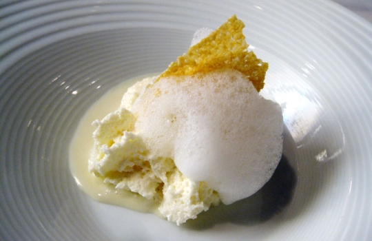 Photogallery






 
Modena’s colonnades, 186 thousand inhabitants and 3 restaurants with at least one Michelin star: Hostaria del Mare (1), Erba del Re (1) and Osteria Francescana (3 stars), our destination
 








Yellow and red tones prevail








The city still bears the signs of the May 2012 earthquake. On May 4th 2013, the day of our visit, a 3.8 magnitude earthquake was registered













By chance, Giuseppe Palmieri, maître and sommelier, appears from the grey door








Palmieri, 38, born in Matera. His first service in Francescana was on September 12th 2000








The old entrance to the restaurant, at number 24 in Via della Stella - as on the opening in 1995. It changed in September 2012: today you enter from number 22. Funnily enough, Google Maps is still set on the old entrance








The present entrance doors








Let’s start








After the latest renovations, the transit areas inside the Osteria appear as a contemporary art gallery








Mario Schifano’s world map








"Tourists", Maurizio Cattelan’s famous pigeons








Underneath the pigeons, Gavin Turk’s “Trashbag”








Three rooms, 12 tables, between 20 to 35 guests. 40% guests are Italian








Every table is illuminated by Davide Groppi’s Sampei lamp: if tables are moved, light follows








Francescana receives 150 reservations every day. But it also suffers from clients not showing up: on average, one table every week is booked but then guests don’t come








Right behind the kitchen, there’s the prêt-à-porter cellar








"In the central cellar, we only keep great vintages and larger bottles of what we consider to be great wines", Beppe Palmieri explains








1,600 wines are listed at Osteria Francescana, with a deep wine list which includes different vintages of the same wine








"A true celebration of wine "








The Ferrari coat, hanging in the cellar: Maranello is only 17 km away from Modena








Jean Todt, Michael Schumacher, Fernando Alonso: Ferrari’s “prancing horse” is at home in Via Stella








Gabrio Bini’s wines, from Pantelleria, a real fetish for Palmieri













Hanging from the ceiling, a nice selection of cured meats from Emilia








Bread made with mother yeast, the premise to a journey which will alternate great classics with very contemporary dishes








Massimo Bottura. Fifty years old last September, he is chef since 1986, the year of Trattoria del Campazzo in Nonantola. His first masters: Lidia Cristoni and Georges Cogny








He’s glowing: a few days ago his restaurant climbed, for the first time, onto the podium of the World's 50Best, a prize that is acquiring an increasing weight and authority. "The thing that makes me the happiest", he says, "is not so much the third place, but the fact that we’ve been in the highest positions for a few years now". True: 13th in 2009, 6th in 2010, 4th in 2011, 5th in 2012, 3rd in 2013








The now famous grey New Balance 993, a real emblem for the chef, friend of Jason Weis, president of the company in Massachusetts. The insole, however, is local: "In Emilia the sector is state-of-the-art", he says








"Are we ready?"








Almond granita with capers, bergamot and coffee cream 
Bottura and Palmieri’s journey across Italy starts from the bottom. And sails off from the Sicilian inland, with a classic granita which in Modena crumbles Adria-style, the wall that divides sweet from savoury, using the picklock of bitterness: Pantelleria capers, wild oregano but also bergamot, a coffee concentrate and vanilla scented salt. To pair with the first part of the meal, Sorriso di Cielo malvasia dei colli piacentini








Mediterranean Macaroon 
Next to the granita, two peculiar macaroons: the first is made with minced anchovies and sardines, the second with oysters and seaweeds. This is a classic scheme in Bottura’scuisine: his ironic turning the order of the dishes, from starter to dessert, upside down, and using popular raw materials instead of ingredients that are emblematic of élite cuisine. «While feet are sinking in the ground, the head is free to move everywhere», is one of his most famous quotes








Tempura of freshwater aulla with carpione ice-cream
Carpione ice-cream on a tempura of freshwater aulla – these fish are similar and slightly bigger than whitebait. The tempura is made by quickly placing the cold batter in boiling oil








Bread and croissants








Grissini








Baccalà Mare Nostrum 
We move up the Tyrrhenian sea to find this salted codfish cooked at low temperature and then seasoned with a touch of Naples and the Amalfi coast, that is to say with an emulsion made with hot oil with tomato vegetal liquid, olives, the zest of Sorrento’s super lemons and some anchovy colatura. These aromas crack with the scented bread on top








40 year old Denis Bretta explains the dishes as if from a book. Once at Restaurant Fini in Modena, for the past year and a half he’s been the manager responsible for the service in the restaurant. But don’t ask Palmieri to explain his role, as he’s abolished all hierarchies: "In our restaurant there are no commis or chef de rang. At a time when titles are so abused, I prefer for us to be all colleagues. All waiters."








How to burn sardines in three days 
Another journey, another horizon, the Adriatic Sea between Romagna and Ancona. A new camouflaged expression: these are not sardines (and they aren’t burnt either) but they are small sea-rock mullet, marinated for 3 days, then seared on one side on a grill, and filled like a sandwich with some (very sweet) scampi cream, and covered with vegetable ashes, aromatic herbs and lemon zest. “I wanted to make fun of the Marche-Romagna habit of grilling everything”, the chef says, “with lemon, garlic and parsley always added later to fix everything”









Rice, between fresh and sea water 
Recalling the Po estuary with freshwater and brackish sensations. The freshwater flavours cover the surface of the oyster which prevails on the river bed. And in the end, catfish, carp, vegetable chlorophyll and carpione win once again








 
A journey to Modena: Adriatic eel, polenta, Campanine apple jelly and saba
Another fluvial odyssey, presented for the first time at Identità Milano in 2011. The Adriatic eel travels across Veneto (with the polenta cream), Mantua (the Campanine apple jelly), the countryside of Modena (with the Saba lacquering, that is to say the mother of Aceto Balsamico) and stops in the centre of Modena (blackened powdered onion, a mimesis of the town’s canals)
 








Normandy
That is to say pre-salè lamb (hanging for 20 days) with an emulsion of oyster water, fresh seaweeds and caviar. On top, a green apple granita that recalls cider. “This is our tribute to Normandy”, Bretta says, “in Modena there are no enchanted beaches or breath-taking mountain tops. From Via Stella you can’t even see the Torre Ghirlandina. What guides us is the persistant strength of ideas, woven into the culture and into memories”








Giovanni Boroni’s Genziana from Trentino. A brilliant idea by Palmieri that acts as a bridge between the two dishes, Normandy (previous picture) and Think Green (next one). This distillate plays an immediate contrast with the sea-character of the first dish: "To me, harmony is what is left after a confrontation", B.P. says. And the confrontation is followed by the thought that spurs from the following match: water is added to the Genziana and the palate surprisingly longs to gulp it all. This is the perfect vehicle for the aromas of the genziana and "gives length" to the minerality of the wild herbs. "This serves to recall water, our true source of richness". Brilliant








Think Green
Vegetal chlorophyll, asparagus tops, pea cream, mushrooms, truffle, flowers, aromatic herbs and Parmigiano Reggiano curd. The idea of this dish came after observing the biological cycle of grazing cows, 4 seasons that sum up all of life. “This is what the cow eats, and what it returns to us, thanks to an extraordinary milk”, Bottura adds





