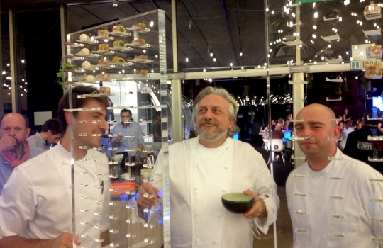 Photogallery






With 250thousand inhabitants, Gent (or Gand) is the third largest city in Belgium. With its canals and its laid back life, it competes with Bruges for the title most beautiful city in the Flanders 








The Sunday began at the Flemish Food Fest, a festival in which everyone was grilling all sorts of food. In the photo, the chef table with many of the chefs that were to be the protagonists of the Gelinaz! dinner








Colagreco, Redzepi and the kitchen-van. The location was kept secret until the beginning of the show, at around 7 pm








The two long tables set at the Icc in Gent. Three shifts: 1-8, 9-16, 17-24. We were so lucky we enjoyed them all








In the kitchen, works to dismember the chickens from Gent begin








"Even I don’t know what will happen tonight. And please remember: this is a performance, not a dinner", says Andrea Petrini, founder and curator of the event named after chef Fulvio Pieran-gelinaz and by Gorillaz, the temporary band that Blur’s Damon Albarn creates whenever he feels like it. The black sculpture underneath the Madonna is that of    Philippe Édouard Cauderlier (Antwerp, 1812-1887)








It all starts by quoting Kubrick and Eyes Wide Shot... Each dish is a song. And each of the three acts is separated by various artistic performances. In the dining room, men act as nothing is going on in front of their partners








First dish of the Gelinaz evening, Philippe Edouard Cauderlier’s Cold-hot chicken timbale, the original recipe from     1861. Roger Souvereyns of Scholteshof in Stevoort had the honour of performing it at the Icc in Gent








Inaki Aizpitarte     ’s Royal chicken kir, using all the ingredients in the original recipe. The wine is diluted in the chicken stock. The dish arrives together with     Wu Tang Clan’s rap








Anataoly Komm of Varvary in Moscow, lets us taste his Maki Roll behind the scenes








Komm’s Maki roll: chicken and vegetables wrapped in a turnip leaf. The sauce is made with walnuts, a Caucasian tradition








Agata Felluga ’s Lotus timbale. She’s the Italian sous chef at Chateaubriand in Paris, with a previous experience at Pascal Barbot’sAstrance. The dish is inspired by a Japanese sticky rice recipe, where the rice is cooked in a lotus leaf. Here, instead, there’s    Cauderlier’s chicken, together with miso, tamarind syrup, pork fat, soy sauce. A very complex dish.








Left, 32 year old Agata Felluga, born in Rome and adopted by the Ville Lumiére








Petter Nilsson’s Bread chicken, from the Gazzetta in Paris. It is made with all the cereals hens eat during their life: corn, hulled wheat, barley, rye and wheat. The photo of the bag is a portrait of the Danish chef’s creation








Massimo Bottura     is not in Gent, however, in a coup de theatre, his brother Paolo takes his place, here on the left with Alberto Buratti,     pastry-chef at Osteria Francescana. The chef from Modena explains in a video the reason behind his absence: "In Modena, his team is so finely     tuned that even my car-salesman brother can take my place", he jokes








Even in Bottura’s dish there’s no traditional chicken: it’s called Chicken, chicken, where are you? It is the re-interpretation     of the classic chicken salad, with a stock made with roasted chicken below, and a cotechino (cooked pork sausage) and agar-agar gelatine with very small dices of peas, carrots, potatoes, red and yellow peppers, onions, tomatoes... in the background, "What about the noise?" by    John Cage strikes us








Pea tendrils with chicken and mint aspic     by Blaine Wetzel, once a pupil of Redzepi, today back home in Lummi Island, a paradise in the middle of nowhere, in     Washington state. The tendrils are grilled. A great dish, with a super balance between smoke, balsamic and acid notes








Chia and chicken with tiger milk, turnips and coca leaves , that is to say "The chicken of Gent meets South America", a journey of the mind, from the Pacific ocean to the Andes to the Amazon forest led by Peruvian    Virgilio Martinez








Virgilio Martinez     at work with Alberto Buratti








Chicken liver, scallion with tarragon, turnip and toasted cauliflower stock by Basque Josean Alija








French-Spanish journalist Maria Canabal and Josean Martinez Alija








Poulet-mayo by Bertrand Grébaut of   Septime in Paris, a cold entrée with all the ingredients of the original recipe. In the background, Rufus Thomas ’s r 'n' b with "Do the funky chicken"








Reneè Redzepi has no doubt when it comes to which is the best part of the chicken: the skin. Half of the guest, as it turned out, agreed with him








Redzepi, on the left, explains his passion for chicken, discovered when he was a child in Macedonia. "I had to prepare this dish at home because it is fucking complicated"








Here it is: it’s not exactly chicken skin, but the “skin” made with a stock prepared using all the ingredients in Cauderlier’s recipe, removing the froth. A single, fantastic morsel, one of the many intervals that compose the first part of a dinner at Noma








We peek into the iPad of Italian Emilia Terragni who works for Phaidon in London, and is sitting at the table next to     ours, and we see a juicy preview: the triple format of Renè Redzepi’s next book, which will be out in November. It’s a sort of diary, an     intimate one, too, in which he explains how difficult dealing with the limelight is








The monumental “skyscrapers” of Six degrees of separations, Davide Scabin’s fantastic idea








In Scabin’s dish, there are 6 of the ingredients in the original recipe, but cooked separately, 6 "morsels" composed by: 1. Porto gelatine with carrot, pea and pea gelatine 2. Chicken mousse filled with livers and two pop corns to keep them firm 3. A pork jelly with tarragon vinegar 4. Cucumber roll with French beans and soy sauce jelly 5. Pork feet and tongue gelatine. And the 6th? Sorry, no response. On the left we find a light chicken royale served in a Martini glass





