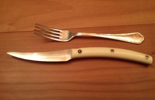 Photogallery






 
Modena’s colonnades, 186 thousand inhabitants and 3 restaurants with at least one Michelin star: Hostaria del Mare (1), Erba del Re (1) and Osteria Francescana (3 stars), our destination
 








Yellow and red tones prevail








The city still bears the signs of the May 2012 earthquake. On May 4th 2013, the day of our visit, a 3.8 magnitude earthquake was registered













By chance, Giuseppe Palmieri, maître and sommelier, appears from the grey door








Palmieri, 38, born in Matera. His first service in Francescana was on September 12th 2000








The old entrance to the restaurant, at number 24 in Via della Stella - as on the opening in 1995. It changed in September 2012: today you enter from number 22. Funnily enough, Google Maps is still set on the old entrance








The present entrance doors








Let’s start








After the latest renovations, the transit areas inside the Osteria appear as a contemporary art gallery








Mario Schifano’s world map








"Tourists", Maurizio Cattelan’s famous pigeons








Underneath the pigeons, Gavin Turk’s “Trashbag”








Three rooms, 12 tables, between 20 to 35 guests. 40% guests are Italian








Every table is illuminated by Davide Groppi’s Sampei lamp: if tables are moved, light follows








Francescana receives 150 reservations every day. But it also suffers from clients not showing up: on average, one table every week is booked but then guests don’t come








Right behind the kitchen, there’s the prêt-à-porter cellar








"In the central cellar, we only keep great vintages and larger bottles of what we consider to be great wines", Beppe Palmieri explains








1,600 wines are listed at Osteria Francescana, with a deep wine list which includes different vintages of the same wine








"A true celebration of wine "








The Ferrari coat, hanging in the cellar: Maranello is only 17 km away from Modena








Jean Todt, Michael Schumacher, Fernando Alonso: Ferrari’s “prancing horse” is at home in Via Stella








Gabrio Bini’s wines, from Pantelleria, a real fetish for Palmieri













Hanging from the ceiling, a nice selection of cured meats from Emilia








Bread made with mother yeast, the premise to a journey which will alternate great classics with very contemporary dishes








Massimo Bottura. Fifty years old last September, he is chef since 1986, the year of Trattoria del Campazzo in Nonantola. His first masters: Lidia Cristoni and Georges Cogny








He’s glowing: a few days ago his restaurant climbed, for the first time, onto the podium of the World's 50Best, a prize that is acquiring an increasing weight and authority. "The thing that makes me the happiest", he says, "is not so much the third place, but the fact that we’ve been in the highest positions for a few years now". True: 13th in 2009, 6th in 2010, 4th in 2011, 5th in 2012, 3rd in 2013








The now famous grey New Balance 993, a real emblem for the chef, friend of Jason Weis, president of the company in Massachusetts. The insole, however, is local: "In Emilia the sector is state-of-the-art", he says








"Are we ready?"








Almond granita with capers, bergamot and coffee cream 
Bottura and Palmieri’s journey across Italy starts from the bottom. And sails off from the Sicilian inland, with a classic granita which in Modena crumbles Adria-style, the wall that divides sweet from savoury, using the picklock of bitterness: Pantelleria capers, wild oregano but also bergamot, a coffee concentrate and vanilla scented salt. To pair with the first part of the meal, Sorriso di Cielo malvasia dei colli piacentini








Mediterranean Macaroon 
Next to the granita, two peculiar macaroons: the first is made with minced anchovies and sardines, the second with oysters and seaweeds. This is a classic scheme in Bottura’scuisine: his ironic turning the order of the dishes, from starter to dessert, upside down, and using popular raw materials instead of ingredients that are emblematic of élite cuisine. «While feet are sinking in the ground, the head is free to move everywhere», is one of his most famous quotes








Tempura of freshwater aulla with carpione ice-cream
Carpione ice-cream on a tempura of freshwater aulla – these fish are similar and slightly bigger than whitebait. The tempura is made by quickly placing the cold batter in boiling oil








Bread and croissants








Grissini








Baccalà Mare Nostrum 
We move up the Tyrrhenian sea to find this salted codfish cooked at low temperature and then seasoned with a touch of Naples and the Amalfi coast, that is to say with an emulsion made with hot oil with tomato vegetal liquid, olives, the zest of Sorrento’s super lemons and some anchovy colatura. These aromas crack with the scented bread on top








40 year old Denis Bretta explains the dishes as if from a book. Once at Restaurant Fini in Modena, for the past year and a half he’s been the manager responsible for the service in the restaurant. But don’t ask Palmieri to explain his role, as he’s abolished all hierarchies: "In our restaurant there are no commis or chef de rang. At a time when titles are so abused, I prefer for us to be all colleagues. All waiters."








How to burn sardines in three days 
Another journey, another horizon, the Adriatic Sea between Romagna and Ancona. A new camouflaged expression: these are not sardines (and they aren’t burnt either) but they are small sea-rock mullet, marinated for 3 days, then seared on one side on a grill, and filled like a sandwich with some (very sweet) scampi cream, and covered with vegetable ashes, aromatic herbs and lemon zest. “I wanted to make fun of the Marche-Romagna habit of grilling everything”, the chef says, “with lemon, garlic and parsley always added later to fix everything”









Rice, between fresh and sea water 
Recalling the Po estuary with freshwater and brackish sensations. The freshwater flavours cover the surface of the oyster which prevails on the river bed. And in the end, catfish, carp, vegetable chlorophyll and carpione win once again








 
A journey to Modena: Adriatic eel, polenta, Campanine apple jelly and saba
Another fluvial odyssey, presented for the first time at Identità Milano in 2011. The Adriatic eel travels across Veneto (with the polenta cream), Mantua (the Campanine apple jelly), the countryside of Modena (with the Saba lacquering, that is to say the mother of Aceto Balsamico) and stops in the centre of Modena (blackened powdered onion, a mimesis of the town’s canals)
 








Normandy
That is to say pre-salè lamb (hanging for 20 days) with an emulsion of oyster water, fresh seaweeds and caviar. On top, a green apple granita that recalls cider. “This is our tribute to Normandy”, Bretta says, “in Modena there are no enchanted beaches or breath-taking mountain tops. From Via Stella you can’t even see the Torre Ghirlandina. What guides us is the persistant strength of ideas, woven into the culture and into memories”








Giovanni Boroni’s Genziana from Trentino. A brilliant idea by Palmieri that acts as a bridge between the two dishes, Normandy (previous picture) and Think Green (next one). This distillate plays an immediate contrast with the sea-character of the first dish: "To me, harmony is what is left after a confrontation", B.P. says. And the confrontation is followed by the thought that spurs from the following match: water is added to the Genziana and the palate surprisingly longs to gulp it all. This is the perfect vehicle for the aromas of the genziana and "gives length" to the minerality of the wild herbs. "This serves to recall water, our true source of richness". Brilliant








Think Green
Vegetal chlorophyll, asparagus tops, pea cream, mushrooms, truffle, flowers, aromatic herbs and Parmigiano Reggiano curd. The idea of this dish came after observing the biological cycle of grazing cows, 4 seasons that sum up all of life. “This is what the cow eats, and what it returns to us, thanks to an extraordinary milk”, Bottura adds








Five ages of Parmigiano Reggiano 
A great classic from 1996, "when the textures in fact were 3", Palmieri points out. Today they are 5: 4 month ageing cream, 30 month demi-soufflè, 36 month mousse, 40 month crispy wafer, on top, “air” of 50 month Parmesan. (photo by Le Saucier)








A compression of pasta and beans 
Another great classic, this is a journey across Bottura’s experiences in the kitchen: Creme royal with pork rind, beans and foie gras (French tradition), rosemary air (the Spanish vanguard) and Parmesan crust (the Emilian essence) used instead of pasta. “This is a dish based on evolution, not revolution. I compressed my grandmother between Alain Ducasse and Ferran Adrià”








Snails under the grapevines 
Snails, aromatic chlorophyll on a bed of wild vegetables and herbs, with mushrooms, truffle and bulbs. After the cow’s life cycle, here comes that of the snail. "Once again, we’re chewing the territory: the best snails slither in the vineyards, among mineral, sapid and acid aromas"








A Frenchman’s dream of making pasta like an Italian 
Or, Ravioli with leeks, foie gras and truffle. We covered this in detail in Identità di Pasta issue number 27








Damijan Podversic’s Ribolla Gialla, a great wine by a wine producer from Gorizia inspired by Josko Gravner. It will support the following dish, without concealing it





