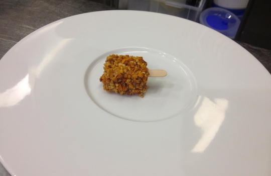 Photogallery






 
Modena’s colonnades, 186 thousand inhabitants and 3 restaurants with at least one Michelin star: Hostaria del Mare (1), Erba del Re (1) and Osteria Francescana (3 stars), our destination
 








Yellow and red tones prevail








The city still bears the signs of the May 2012 earthquake. On May 4th 2013, the day of our visit, a 3.8 magnitude earthquake was registered













By chance, Giuseppe Palmieri, maître and sommelier, appears from the grey door








Palmieri, 38, born in Matera. His first service in Francescana was on September 12th 2000








The old entrance to the restaurant, at number 24 in Via della Stella - as on the opening in 1995. It changed in September 2012: today you enter from number 22. Funnily enough, Google Maps is still set on the old entrance








The present entrance doors








Let’s start








After the latest renovations, the transit areas inside the Osteria appear as a contemporary art gallery








Mario Schifano’s world map








"Tourists", Maurizio Cattelan’s famous pigeons








Underneath the pigeons, Gavin Turk’s “Trashbag”








Three rooms, 12 tables, between 20 to 35 guests. 40% guests are Italian








Every table is illuminated by Davide Groppi’s Sampei lamp: if tables are moved, light follows








Francescana receives 150 reservations every day. But it also suffers from clients not showing up: on average, one table every week is booked but then guests don’t come








Right behind the kitchen, there’s the prêt-à-porter cellar








"In the central cellar, we only keep great vintages and larger bottles of what we consider to be great wines", Beppe Palmieri explains








1,600 wines are listed at Osteria Francescana, with a deep wine list which includes different vintages of the same wine








"A true celebration of wine "








The Ferrari coat, hanging in the cellar: Maranello is only 17 km away from Modena








Jean Todt, Michael Schumacher, Fernando Alonso: Ferrari’s “prancing horse” is at home in Via Stella








Gabrio Bini’s wines, from Pantelleria, a real fetish for Palmieri













Hanging from the ceiling, a nice selection of cured meats from Emilia








Bread made with mother yeast, the premise to a journey which will alternate great classics with very contemporary dishes








Massimo Bottura. Fifty years old last September, he is chef since 1986, the year of Trattoria del Campazzo in Nonantola. His first masters: Lidia Cristoni and Georges Cogny








He’s glowing: a few days ago his restaurant climbed, for the first time, onto the podium of the World's 50Best, a prize that is acquiring an increasing weight and authority. "The thing that makes me the happiest", he says, "is not so much the third place, but the fact that we’ve been in the highest positions for a few years now". True: 13th in 2009, 6th in 2010, 4th in 2011, 5th in 2012, 3rd in 2013








The now famous grey New Balance 993, a real emblem for the chef, friend of Jason Weis, president of the company in Massachusetts. The insole, however, is local: "In Emilia the sector is state-of-the-art", he says








"Are we ready?"








Almond granita with capers, bergamot and coffee cream 
Bottura and Palmieri’s journey across Italy starts from the bottom. And sails off from the Sicilian inland, with a classic granita which in Modena crumbles Adria-style, the wall that divides sweet from savoury, using the picklock of bitterness: Pantelleria capers, wild oregano but also bergamot, a coffee concentrate and vanilla scented salt. To pair with the first part of the meal, Sorriso di Cielo malvasia dei colli piacentini








Mediterranean Macaroon 
Next to the granita, two peculiar macaroons: the first is made with minced anchovies and sardines, the second with oysters and seaweeds. This is a classic scheme in Bottura’scuisine: his ironic turning the order of the dishes, from starter to dessert, upside down, and using popular raw materials instead of ingredients that are emblematic of élite cuisine. «While feet are sinking in the ground, the head is free to move everywhere», is one of his most famous quotes








Tempura of freshwater aulla with carpione ice-cream
Carpione ice-cream on a tempura of freshwater aulla – these fish are similar and slightly bigger than whitebait. The tempura is made by quickly placing the cold batter in boiling oil








Bread and croissants








Grissini








Baccalà Mare Nostrum 
We move up the Tyrrhenian sea to find this salted codfish cooked at low temperature and then seasoned with a touch of Naples and the Amalfi coast, that is to say with an emulsion made with hot oil with tomato vegetal liquid, olives, the zest of Sorrento’s super lemons and some anchovy colatura. These aromas crack with the scented bread on top








40 year old Denis Bretta explains the dishes as if from a book. Once at Restaurant Fini in Modena, for the past year and a half he’s been the manager responsible for the service in the restaurant. But don’t ask Palmieri to explain his role, as he’s abolished all hierarchies: "In our restaurant there are no commis or chef de rang. At a time when titles are so abused, I prefer for us to be all colleagues. All waiters."








How to burn sardines in three days 
Another journey, another horizon, the Adriatic Sea between Romagna and Ancona. A new camouflaged expression: these are not sardines (and they aren’t burnt either) but they are small sea-rock mullet, marinated for 3 days, then seared on one side on a grill, and filled like a sandwich with some (very sweet) scampi cream, and covered with vegetable ashes, aromatic herbs and lemon zest. “I wanted to make fun of the Marche-Romagna habit of grilling everything”, the chef says, “with lemon, garlic and parsley always added later to fix everything”









Rice, between fresh and sea water 
Recalling the Po estuary with freshwater and brackish sensations. The freshwater flavours cover the surface of the oyster which prevails on the river bed. And in the end, catfish, carp, vegetable chlorophyll and carpione win once again








 
A journey to Modena: Adriatic eel, polenta, Campanine apple jelly and saba
Another fluvial odyssey, presented for the first time at Identità Milano in 2011. The Adriatic eel travels across Veneto (with the polenta cream), Mantua (the Campanine apple jelly), the countryside of Modena (with the Saba lacquering, that is to say the mother of Aceto Balsamico) and stops in the centre of Modena (blackened powdered onion, a mimesis of the town’s canals)
 








Normandy
That is to say pre-salè lamb (hanging for 20 days) with an emulsion of oyster water, fresh seaweeds and caviar. On top, a green apple granita that recalls cider. “This is our tribute to Normandy”, Bretta says, “in Modena there are no enchanted beaches or breath-taking mountain tops. From Via Stella you can’t even see the Torre Ghirlandina. What guides us is the persistant strength of ideas, woven into the culture and into memories”








Giovanni Boroni’s Genziana from Trentino. A brilliant idea by Palmieri that acts as a bridge between the two dishes, Normandy (previous picture) and Think Green (next one). This distillate plays an immediate contrast with the sea-character of the first dish: "To me, harmony is what is left after a confrontation", B.P. says. And the confrontation is followed by the thought that spurs from the following match: water is added to the Genziana and the palate surprisingly longs to gulp it all. This is the perfect vehicle for the aromas of the genziana and "gives length" to the minerality of the wild herbs. "This serves to recall water, our true source of richness". Brilliant








Think Green
Vegetal chlorophyll, asparagus tops, pea cream, mushrooms, truffle, flowers, aromatic herbs and Parmigiano Reggiano curd. The idea of this dish came after observing the biological cycle of grazing cows, 4 seasons that sum up all of life. “This is what the cow eats, and what it returns to us, thanks to an extraordinary milk”, Bottura adds








Five ages of Parmigiano Reggiano 
A great classic from 1996, "when the textures in fact were 3", Palmieri points out. Today they are 5: 4 month ageing cream, 30 month demi-soufflè, 36 month mousse, 40 month crispy wafer, on top, “air” of 50 month Parmesan. (photo by Le Saucier)








A compression of pasta and beans 
Another great classic, this is a journey across Bottura’s experiences in the kitchen: Creme royal with pork rind, beans and foie gras (French tradition), rosemary air (the Spanish vanguard) and Parmesan crust (the Emilian essence) used instead of pasta. “This is a dish based on evolution, not revolution. I compressed my grandmother between Alain Ducasse and Ferran Adrià”








Snails under the grapevines 
Snails, aromatic chlorophyll on a bed of wild vegetables and herbs, with mushrooms, truffle and bulbs. After the cow’s life cycle, here comes that of the snail. "Once again, we’re chewing the territory: the best snails slither in the vineyards, among mineral, sapid and acid aromas"








A Frenchman’s dream of making pasta like an Italian 
Or, Ravioli with leeks, foie gras and truffle. We covered this in detail in Identità di Pasta issue number 27








Damijan Podversic’s Ribolla Gialla, a great wine by a wine producer from Gorizia inspired by Josko Gravner. It will support the following dish, without concealing it








A sharp knife is only served now. Another sign of the “allergy” to lengthy chewing that characterises most of contemporary high cuisine








Pigeon hunt 
And over to Bretta: "This is served in a balsamic sauce made with beetroots, which recalls blood. The salad is made with fake leaves, made by cutting out some tubers using some small stamps. These are then compressed in a vacuum with different types of vinegar. The horseradish is grated a few seconds before service, to give some velocity to the pigeon". Irony wins, since "pigeons are not hunted". The bird supplier is Franco Cazzamali from Cremona








Before the dessert, a trip to the restroom: vegetal notes prevail here too








A visit to the kitchen: capon stock








The chef watches over everything, even on the loud music wired wireless from the ceiling. When we get inside, Rod Stewart is screaming "Do you think I'm sexy?"








Meanwhile, the sauces are prepared for the evening service. There’s no break between lunch and dinner. "People sometimes leave at 5 pm because they come here to enjoy the experience of a lifetime", Palmieri reveals, "We work non-stop and every year is worse (or better, that is to say). Don’t ask me anything after midnight, though, because I can’t think straight"








Between dining room and kitchen, today 27 people work at Osteria Francescana. Many of them are interns: "Had I been offered an internship with Ducasse, at the time”, Bottura says, "I would have paid myself". In fact, he really took an internship at the Louis XV in Monte Carlo, in 1992








Leaves 
The journey takes us amidst the forests beds in Umbria: the real leaves change according to the season (black cabbage in winter, red and green basil in spring), they are caramelised and then worked with some chestnut and hazelnut paste, with a vin brulée reduction, chocolate and citrus fruits concentrate...





