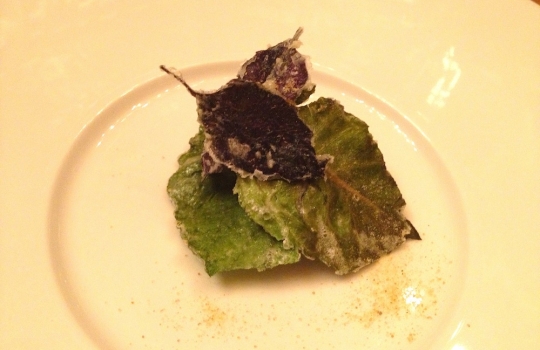 Photogallery






 
Modena’s colonnades, 186 thousand inhabitants and 3 restaurants with at least one Michelin star: Hostaria del Mare (1), Erba del Re (1) and Osteria Francescana (3 stars), our destination
 








Yellow and red tones prevail








The city still bears the signs of the May 2012 earthquake. On May 4th 2013, the day of our visit, a 3.8 magnitude earthquake was registered













By chance, Giuseppe Palmieri, maître and sommelier, appears from the grey door








Palmieri, 38, born in Matera. His first service in Francescana was on September 12th 2000








The old entrance to the restaurant, at number 24 in Via della Stella - as on the opening in 1995. It changed in September 2012: today you enter from number 22. Funnily enough, Google Maps is still set on the old entrance








The present entrance doors








Let’s start








After the latest renovations, the transit areas inside the Osteria appear as a contemporary art gallery








Mario Schifano’s world map








"Tourists", Maurizio Cattelan’s famous pigeons








Underneath the pigeons, Gavin Turk’s “Trashbag”








Three rooms, 12 tables, between 20 to 35 guests. 40% guests are Italian








Every table is illuminated by Davide Groppi’s Sampei lamp: if tables are moved, light follows








Francescana receives 150 reservations every day. But it also suffers from clients not showing up: on average, one table every week is booked but then guests don’t come








Right behind the kitchen, there’s the prêt-à-porter cellar








"In the central cellar, we only keep great vintages and larger bottles of what we consider to be great wines", Beppe Palmieri explains








1,600 wines are listed at Osteria Francescana, with a deep wine list which includes different vintages of the same wine








"A true celebration of wine "








The Ferrari coat, hanging in the cellar: Maranello is only 17 km away from Modena








Jean Todt, Michael Schumacher, Fernando Alonso: Ferrari’s “prancing horse” is at home in Via Stella








Gabrio Bini’s wines, from Pantelleria, a real fetish for Palmieri













Hanging from the ceiling, a nice selection of cured meats from Emilia








Bread made with mother yeast, the premise to a journey which will alternate great classics with very contemporary dishes








Massimo Bottura. Fifty years old last September, he is chef since 1986, the year of Trattoria del Campazzo in Nonantola. His first masters: Lidia Cristoni and Georges Cogny








He’s glowing: a few days ago his restaurant climbed, for the first time, onto the podium of the World's 50Best, a prize that is acquiring an increasing weight and authority. "The thing that makes me the happiest", he says, "is not so much the third place, but the fact that we’ve been in the highest positions for a few years now". True: 13th in 2009, 6th in 2010, 4th in 2011, 5th in 2012, 3rd in 2013








The now famous grey New Balance 993, a real emblem for the chef, friend of Jason Weis, president of the company in Massachusetts. The insole, however, is local: "In Emilia the sector is state-of-the-art", he says








"Are we ready?"








Almond granita with capers, bergamot and coffee cream 
Bottura and Palmieri’s journey across Italy starts from the bottom. And sails off from the Sicilian inland, with a classic granita which in Modena crumbles Adria-style, the wall that divides sweet from savoury, using the picklock of bitterness: Pantelleria capers, wild oregano but also bergamot, a coffee concentrate and vanilla scented salt. To pair with the first part of the meal, Sorriso di Cielo malvasia dei colli piacentini








Mediterranean Macaroon 
Next to the granita, two peculiar macaroons: the first is made with minced anchovies and sardines, the second with oysters and seaweeds. This is a classic scheme in Bottura’scuisine: his ironic turning the order of the dishes, from starter to dessert, upside down, and using popular raw materials instead of ingredients that are emblematic of élite cuisine. «While feet are sinking in the ground, the head is free to move everywhere», is one of his most famous quotes








Tempura of freshwater aulla with carpione ice-cream
Carpione ice-cream on a tempura of freshwater aulla – these fish are similar and slightly bigger than whitebait. The tempura is made by quickly placing the cold batter in boiling oil








Bread and croissants








Grissini








Baccalà Mare Nostrum 
We move up the Tyrrhenian sea to find this salted codfish cooked at low temperature and then seasoned with a touch of Naples and the Amalfi coast, that is to say with an emulsion made with hot oil with tomato vegetal liquid, olives, the zest of Sorrento’s super lemons and some anchovy colatura. These aromas crack with the scented bread on top








40 year old Denis Bretta explains the dishes as if from a book. Once at Restaurant Fini in Modena, for the past year and a half he’s been the manager responsible for the service in the restaurant. But don’t ask Palmieri to explain his role, as he’s abolished all hierarchies: "In our restaurant there are no commis or chef de rang. At a time when titles are so abused, I prefer for us to be all colleagues. All waiters."








How to burn sardines in three days 
Another journey, another horizon, the Adriatic Sea between Romagna and Ancona. A new camouflaged expression: these are not sardines (and they aren’t burnt either) but they are small sea-rock mullet, marinated for 3 days, then seared on one side on a grill, and filled like a sandwich with some (very sweet) scampi cream, and covered with vegetable ashes, aromatic herbs and lemon zest. “I wanted to make fun of the Marche-Romagna habit of grilling everything”, the chef says, “with lemon, garlic and parsley always added later to fix everything”









Rice, between fresh and sea water 
Recalling the Po estuary with freshwater and brackish sensations. The freshwater flavours cover the surface of the oyster which prevails on the river bed. And in the end, catfish, carp, vegetable chlorophyll and carpione win once again








 
A journey to Modena: Adriatic eel, polenta, Campanine apple jelly and saba
Another fluvial odyssey, presented for the first time at Identità Milano in 2011. The Adriatic eel travels across Veneto (with the polenta cream), Mantua (the Campanine apple jelly), the countryside of Modena (with the Saba lacquering, that is to say the mother of Aceto Balsamico) and stops in the centre of Modena (blackened powdered onion, a mimesis of the town’s canals)
 








Normandy
That is to say pre-salè lamb (hanging for 20 days) with an emulsion of oyster water, fresh seaweeds and caviar. On top, a green apple granita that recalls cider. “This is our tribute to Normandy”, Bretta says, “in Modena there are no enchanted beaches or breath-taking mountain tops. From Via Stella you can’t even see the Torre Ghirlandina. What guides us is the persistant strength of ideas, woven into the culture and into memories”








Giovanni Boroni’s Genziana from Trentino. A brilliant idea by Palmieri that acts as a bridge between the two dishes, Normandy (previous picture) and Think Green (next one). This distillate plays an immediate contrast with the sea-character of the first dish: "To me, harmony is what is left after a confrontation", B.P. says. And the confrontation is followed by the thought that spurs from the following match: water is added to the Genziana and the palate surprisingly longs to gulp it all. This is the perfect vehicle for the aromas of the genziana and "gives length" to the minerality of the wild herbs. "This serves to recall water, our true source of richness". Brilliant








Think Green
Vegetal chlorophyll, asparagus tops, pea cream, mushrooms, truffle, flowers, aromatic herbs and Parmigiano Reggiano curd. The idea of this dish came after observing the biological cycle of grazing cows, 4 seasons that sum up all of life. “This is what the cow eats, and what it returns to us, thanks to an extraordinary milk”, Bottura adds








Five ages of Parmigiano Reggiano 
A great classic from 1996, "when the textures in fact were 3", Palmieri points out. Today they are 5: 4 month ageing cream, 30 month demi-soufflè, 36 month mousse, 40 month crispy wafer, on top, “air” of 50 month Parmesan. (photo by Le Saucier)








A compression of pasta and beans 
Another great classic, this is a journey across Bottura’s experiences in the kitchen: Creme royal with pork rind, beans and foie gras (French tradition), rosemary air (the Spanish vanguard) and Parmesan crust (the Emilian essence) used instead of pasta. “This is a dish based on evolution, not revolution. I compressed my grandmother between Alain Ducasse and Ferran Adrià”








Snails under the grapevines 
Snails, aromatic chlorophyll on a bed of wild vegetables and herbs, with mushrooms, truffle and bulbs. After the cow’s life cycle, here comes that of the snail. "Once again, we’re chewing the territory: the best snails slither in the vineyards, among mineral, sapid and acid aromas"








A Frenchman’s dream of making pasta like an Italian 
Or, Ravioli with leeks, foie gras and truffle. We covered this in detail in Identità di Pasta issue number 27








Damijan Podversic’s Ribolla Gialla, a great wine by a wine producer from Gorizia inspired by Josko Gravner. It will support the following dish, without concealing it








A sharp knife is only served now. Another sign of the “allergy” to lengthy chewing that characterises most of contemporary high cuisine








Pigeon hunt 
And over to Bretta: "This is served in a balsamic sauce made with beetroots, which recalls blood. The salad is made with fake leaves, made by cutting out some tubers using some small stamps. These are then compressed in a vacuum with different types of vinegar. The horseradish is grated a few seconds before service, to give some velocity to the pigeon". Irony wins, since "pigeons are not hunted". The bird supplier is Franco Cazzamali from Cremona








Before the dessert, a trip to the restroom: vegetal notes prevail here too








A visit to the kitchen: capon stock








The chef watches over everything, even on the loud music wired wireless from the ceiling. When we get inside, Rod Stewart is screaming "Do you think I'm sexy?"








Meanwhile, the sauces are prepared for the evening service. There’s no break between lunch and dinner. "People sometimes leave at 5 pm because they come here to enjoy the experience of a lifetime", Palmieri reveals, "We work non-stop and every year is worse (or better, that is to say). Don’t ask me anything after midnight, though, because I can’t think straight"








Between dining room and kitchen, today 27 people work at Osteria Francescana. Many of them are interns: "Had I been offered an internship with Ducasse, at the time”, Bottura says, "I would have paid myself". In fact, he really took an internship at the Louis XV in Monte Carlo, in 1992





