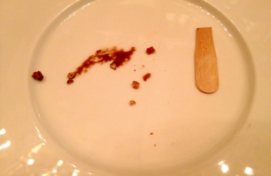 Photogallery






 
Modena’s colonnades, 186 thousand inhabitants and 3 restaurants with at least one Michelin star: Hostaria del Mare (1), Erba del Re (1) and Osteria Francescana (3 stars), our destination
 








Yellow and red tones prevail








The city still bears the signs of the May 2012 earthquake. On May 4th 2013, the day of our visit, a 3.8 magnitude earthquake was registered













By chance, Giuseppe Palmieri, maître and sommelier, appears from the grey door








Palmieri, 38, born in Matera. His first service in Francescana was on September 12th 2000








The old entrance to the restaurant, at number 24 in Via della Stella - as on the opening in 1995. It changed in September 2012: today you enter from number 22. Funnily enough, Google Maps is still set on the old entrance








The present entrance doors








Let’s start








After the latest renovations, the transit areas inside the Osteria appear as a contemporary art gallery








Mario Schifano’s world map








"Tourists", Maurizio Cattelan’s famous pigeons








Underneath the pigeons, Gavin Turk’s “Trashbag”








Three rooms, 12 tables, between 20 to 35 guests. 40% guests are Italian








Every table is illuminated by Davide Groppi’s Sampei lamp: if tables are moved, light follows








Francescana receives 150 reservations every day. But it also suffers from clients not showing up: on average, one table every week is booked but then guests don’t come








Right behind the kitchen, there’s the prêt-à-porter cellar








"In the central cellar, we only keep great vintages and larger bottles of what we consider to be great wines", Beppe Palmieri explains








1,600 wines are listed at Osteria Francescana, with a deep wine list which includes different vintages of the same wine








"A true celebration of wine "








The Ferrari coat, hanging in the cellar: Maranello is only 17 km away from Modena








Jean Todt, Michael Schumacher, Fernando Alonso: Ferrari’s “prancing horse” is at home in Via Stella








Gabrio Bini’s wines, from Pantelleria, a real fetish for Palmieri













Hanging from the ceiling, a nice selection of cured meats from Emilia








Bread made with mother yeast, the premise to a journey which will alternate great classics with very contemporary dishes








Massimo Bottura. Fifty years old last September, he is chef since 1986, the year of Trattoria del Campazzo in Nonantola. His first masters: Lidia Cristoni and Georges Cogny








He’s glowing: a few days ago his restaurant climbed, for the first time, onto the podium of the World's 50Best, a prize that is acquiring an increasing weight and authority. "The thing that makes me the happiest", he says, "is not so much the third place, but the fact that we’ve been in the highest positions for a few years now". True: 13th in 2009, 6th in 2010, 4th in 2011, 5th in 2012, 3rd in 2013








The now famous grey New Balance 993, a real emblem for the chef, friend of Jason Weis, president of the company in Massachusetts. The insole, however, is local: "In Emilia the sector is state-of-the-art", he says








"Are we ready?"








Almond granita with capers, bergamot and coffee cream 
Bottura and Palmieri’s journey across Italy starts from the bottom. And sails off from the Sicilian inland, with a classic granita which in Modena crumbles Adria-style, the wall that divides sweet from savoury, using the picklock of bitterness: Pantelleria capers, wild oregano but also bergamot, a coffee concentrate and vanilla scented salt. To pair with the first part of the meal, Sorriso di Cielo malvasia dei colli piacentini








Mediterranean Macaroon 
Next to the granita, two peculiar macaroons: the first is made with minced anchovies and sardines, the second with oysters and seaweeds. This is a classic scheme in Bottura’scuisine: his ironic turning the order of the dishes, from starter to dessert, upside down, and using popular raw materials instead of ingredients that are emblematic of élite cuisine. «While feet are sinking in the ground, the head is free to move everywhere», is one of his most famous quotes








Tempura of freshwater aulla with carpione ice-cream
Carpione ice-cream on a tempura of freshwater aulla – these fish are similar and slightly bigger than whitebait. The tempura is made by quickly placing the cold batter in boiling oil








Bread and croissants








Grissini








Baccalà Mare Nostrum 
We move up the Tyrrhenian sea to find this salted codfish cooked at low temperature and then seasoned with a touch of Naples and the Amalfi coast, that is to say with an emulsion made with hot oil with tomato vegetal liquid, olives, the zest of Sorrento’s super lemons and some anchovy colatura. These aromas crack with the scented bread on top








40 year old Denis Bretta explains the dishes as if from a book. Once at Restaurant Fini in Modena, for the past year and a half he’s been the manager responsible for the service in the restaurant. But don’t ask Palmieri to explain his role, as he’s abolished all hierarchies: "In our restaurant there are no commis or chef de rang. At a time when titles are so abused, I prefer for us to be all colleagues. All waiters."








How to burn sardines in three days 
Another journey, another horizon, the Adriatic Sea between Romagna and Ancona. A new camouflaged expression: these are not sardines (and they aren’t burnt either) but they are small sea-rock mullet, marinated for 3 days, then seared on one side on a grill, and filled like a sandwich with some (very sweet) scampi cream, and covered with vegetable ashes, aromatic herbs and lemon zest. “I wanted to make fun of the Marche-Romagna habit of grilling everything”, the chef says, “with lemon, garlic and parsley always added later to fix everything”









Rice, between fresh and sea water 
Recalling the Po estuary with freshwater and brackish sensations. The freshwater flavours cover the surface of the oyster which prevails on the river bed. And in the end, catfish, carp, vegetable chlorophyll and carpione win once again








 
A journey to Modena: Adriatic eel, polenta, Campanine apple jelly and saba
Another fluvial odyssey, presented for the first time at Identità Milano in 2011. The Adriatic eel travels across Veneto (with the polenta cream), Mantua (the Campanine apple jelly), the countryside of Modena (with the Saba lacquering, that is to say the mother of Aceto Balsamico) and stops in the centre of Modena (blackened powdered onion, a mimesis of the town’s canals)
 








Normandy
That is to say pre-salè lamb (hanging for 20 days) with an emulsion of oyster water, fresh seaweeds and caviar. On top, a green apple granita that recalls cider. “This is our tribute to Normandy”, Bretta says, “in Modena there are no enchanted beaches or breath-taking mountain tops. From Via Stella you can’t even see the Torre Ghirlandina. What guides us is the persistant strength of ideas, woven into the culture and into memories”








Giovanni Boroni’s Genziana from Trentino. A brilliant idea by Palmieri that acts as a bridge between the two dishes, Normandy (previous picture) and Think Green (next one). This distillate plays an immediate contrast with the sea-character of the first dish: "To me, harmony is what is left after a confrontation", B.P. says. And the confrontation is followed by the thought that spurs from the following match: water is added to the Genziana and the palate surprisingly longs to gulp it all. This is the perfect vehicle for the aromas of the genziana and "gives length" to the minerality of the wild herbs. "This serves to recall water, our true source of richness". Brilliant








Think Green
Vegetal chlorophyll, asparagus tops, pea cream, mushrooms, truffle, flowers, aromatic herbs and Parmigiano Reggiano curd. The idea of this dish came after observing the biological cycle of grazing cows, 4 seasons that sum up all of life. “This is what the cow eats, and what it returns to us, thanks to an extraordinary milk”, Bottura adds








Five ages of Parmigiano Reggiano 
A great classic from 1996, "when the textures in fact were 3", Palmieri points out. Today they are 5: 4 month ageing cream, 30 month demi-soufflè, 36 month mousse, 40 month crispy wafer, on top, “air” of 50 month Parmesan. (photo by Le Saucier)








A compression of pasta and beans 
Another great classic, this is a journey across Bottura’s experiences in the kitchen: Creme royal with pork rind, beans and foie gras (French tradition), rosemary air (the Spanish vanguard) and Parmesan crust (the Emilian essence) used instead of pasta. “This is a dish based on evolution, not revolution. I compressed my grandmother between Alain Ducasse and Ferran Adrià”








Snails under the grapevines 
Snails, aromatic chlorophyll on a bed of wild vegetables and herbs, with mushrooms, truffle and bulbs. After the cow’s life cycle, here comes that of the snail. "Once again, we’re chewing the territory: the best snails slither in the vineyards, among mineral, sapid and acid aromas"








A Frenchman’s dream of making pasta like an Italian 
Or, Ravioli with leeks, foie gras and truffle. We covered this in detail in Identità di Pasta issue number 27








Damijan Podversic’s Ribolla Gialla, a great wine by a wine producer from Gorizia inspired by Josko Gravner. It will support the following dish, without concealing it








A sharp knife is only served now. Another sign of the “allergy” to lengthy chewing that characterises most of contemporary high cuisine








Pigeon hunt 
And over to Bretta: "This is served in a balsamic sauce made with beetroots, which recalls blood. The salad is made with fake leaves, made by cutting out some tubers using some small stamps. These are then compressed in a vacuum with different types of vinegar. The horseradish is grated a few seconds before service, to give some velocity to the pigeon". Irony wins, since "pigeons are not hunted". The bird supplier is Franco Cazzamali from Cremona








Before the dessert, a trip to the restroom: vegetal notes prevail here too








A visit to the kitchen: capon stock








The chef watches over everything, even on the loud music wired wireless from the ceiling. When we get inside, Rod Stewart is screaming "Do you think I'm sexy?"








Meanwhile, the sauces are prepared for the evening service. There’s no break between lunch and dinner. "People sometimes leave at 5 pm because they come here to enjoy the experience of a lifetime", Palmieri reveals, "We work non-stop and every year is worse (or better, that is to say). Don’t ask me anything after midnight, though, because I can’t think straight"








Between dining room and kitchen, today 27 people work at Osteria Francescana. Many of them are interns: "Had I been offered an internship with Ducasse, at the time”, Bottura says, "I would have paid myself". In fact, he really took an internship at the Louis XV in Monte Carlo, in 1992








Leaves 
The journey takes us amidst the forests beds in Umbria: the real leaves change according to the season (black cabbage in winter, red and green basil in spring), they are caramelised and then worked with some chestnut and hazelnut paste, with a vin brulée reduction, chocolate and citrus fruits concentrate...








Magnum of Foie gras (before)
A foie gras terrine, vacuum cooked, covered with powdered toasted hazelnuts and chopped toasted almonds, finished with some apple Balsamic Vinegar. This is possibly Massimo Bottura’s most famous (and copied) dish. Alessandra Meldolesi, in her book "Sei. Autirotratto della cucina italiana d'avanguardia" she writes: "It’s a trompe-l’oeil starter in which a mould unmistakably used in the food industry, encloses the secret of the most exclusive delicacies, foie gras and Aceto Balsamico Tradizionale. This is snack versus high cuisine, dessert versus starter, entremets versus carne: the triple antiphrasis manages to get a smile"





