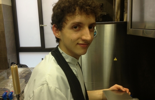 Photogallery






 
Modena’s colonnades, 186 thousand inhabitants and 3 restaurants with at least one Michelin star: Hostaria del Mare (1), Erba del Re (1) and Osteria Francescana (3 stars), our destination
 








Yellow and red tones prevail








The city still bears the signs of the May 2012 earthquake. On May 4th 2013, the day of our visit, a 3.8 magnitude earthquake was registered













By chance, Giuseppe Palmieri, maître and sommelier, appears from the grey door








Palmieri, 38, born in Matera. His first service in Francescana was on September 12th 2000








The old entrance to the restaurant, at number 24 in Via della Stella - as on the opening in 1995. It changed in September 2012: today you enter from number 22. Funnily enough, Google Maps is still set on the old entrance








The present entrance doors








Let’s start








After the latest renovations, the transit areas inside the Osteria appear as a contemporary art gallery








Mario Schifano’s world map








"Tourists", Maurizio Cattelan’s famous pigeons








Underneath the pigeons, Gavin Turk’s “Trashbag”








Three rooms, 12 tables, between 20 to 35 guests. 40% guests are Italian








Every table is illuminated by Davide Groppi’s Sampei lamp: if tables are moved, light follows








Francescana receives 150 reservations every day. But it also suffers from clients not showing up: on average, one table every week is booked but then guests don’t come








Right behind the kitchen, there’s the prêt-à-porter cellar








"In the central cellar, we only keep great vintages and larger bottles of what we consider to be great wines", Beppe Palmieri explains








1,600 wines are listed at Osteria Francescana, with a deep wine list which includes different vintages of the same wine








"A true celebration of wine "








The Ferrari coat, hanging in the cellar: Maranello is only 17 km away from Modena








Jean Todt, Michael Schumacher, Fernando Alonso: Ferrari’s “prancing horse” is at home in Via Stella








Gabrio Bini’s wines, from Pantelleria, a real fetish for Palmieri













Hanging from the ceiling, a nice selection of cured meats from Emilia








Bread made with mother yeast, the premise to a journey which will alternate great classics with very contemporary dishes








Massimo Bottura. Fifty years old last September, he is chef since 1986, the year of Trattoria del Campazzo in Nonantola. His first masters: Lidia Cristoni and Georges Cogny








He’s glowing: a few days ago his restaurant climbed, for the first time, onto the podium of the World's 50Best, a prize that is acquiring an increasing weight and authority. "The thing that makes me the happiest", he says, "is not so much the third place, but the fact that we’ve been in the highest positions for a few years now". True: 13th in 2009, 6th in 2010, 4th in 2011, 5th in 2012, 3rd in 2013








The now famous grey New Balance 993, a real emblem for the chef, friend of Jason Weis, president of the company in Massachusetts. The insole, however, is local: "In Emilia the sector is state-of-the-art", he says








"Are we ready?"








Almond granita with capers, bergamot and coffee cream 
Bottura and Palmieri’s journey across Italy starts from the bottom. And sails off from the Sicilian inland, with a classic granita which in Modena crumbles Adria-style, the wall that divides sweet from savoury, using the picklock of bitterness: Pantelleria capers, wild oregano but also bergamot, a coffee concentrate and vanilla scented salt. To pair with the first part of the meal, Sorriso di Cielo malvasia dei colli piacentini








Mediterranean Macaroon 
Next to the granita, two peculiar macaroons: the first is made with minced anchovies and sardines, the second with oysters and seaweeds. This is a classic scheme in Bottura’scuisine: his ironic turning the order of the dishes, from starter to dessert, upside down, and using popular raw materials instead of ingredients that are emblematic of élite cuisine. «While feet are sinking in the ground, the head is free to move everywhere», is one of his most famous quotes








Tempura of freshwater aulla with carpione ice-cream
Carpione ice-cream on a tempura of freshwater aulla – these fish are similar and slightly bigger than whitebait. The tempura is made by quickly placing the cold batter in boiling oil








Bread and croissants








Grissini








Baccalà Mare Nostrum 
We move up the Tyrrhenian sea to find this salted codfish cooked at low temperature and then seasoned with a touch of Naples and the Amalfi coast, that is to say with an emulsion made with hot oil with tomato vegetal liquid, olives, the zest of Sorrento’s super lemons and some anchovy colatura. These aromas crack with the scented bread on top








40 year old Denis Bretta explains the dishes as if from a book. Once at Restaurant Fini in Modena, for the past year and a half he’s been the manager responsible for the service in the restaurant. But don’t ask Palmieri to explain his role, as he’s abolished all hierarchies: "In our restaurant there are no commis or chef de rang. At a time when titles are so abused, I prefer for us to be all colleagues. All waiters."








How to burn sardines in three days 
Another journey, another horizon, the Adriatic Sea between Romagna and Ancona. A new camouflaged expression: these are not sardines (and they aren’t burnt either) but they are small sea-rock mullet, marinated for 3 days, then seared on one side on a grill, and filled like a sandwich with some (very sweet) scampi cream, and covered with vegetable ashes, aromatic herbs and lemon zest. “I wanted to make fun of the Marche-Romagna habit of grilling everything”, the chef says, “with lemon, garlic and parsley always added later to fix everything”









Rice, between fresh and sea water 
Recalling the Po estuary with freshwater and brackish sensations. The freshwater flavours cover the surface of the oyster which prevails on the river bed. And in the end, catfish, carp, vegetable chlorophyll and carpione win once again








 
A journey to Modena: Adriatic eel, polenta, Campanine apple jelly and saba
Another fluvial odyssey, presented for the first time at Identità Milano in 2011. The Adriatic eel travels across Veneto (with the polenta cream), Mantua (the Campanine apple jelly), the countryside of Modena (with the Saba lacquering, that is to say the mother of Aceto Balsamico) and stops in the centre of Modena (blackened powdered onion, a mimesis of the town’s canals)
 








Normandy
That is to say pre-salè lamb (hanging for 20 days) with an emulsion of oyster water, fresh seaweeds and caviar. On top, a green apple granita that recalls cider. “This is our tribute to Normandy”, Bretta says, “in Modena there are no enchanted beaches or breath-taking mountain tops. From Via Stella you can’t even see the Torre Ghirlandina. What guides us is the persistant strength of ideas, woven into the culture and into memories”








Giovanni Boroni’s Genziana from Trentino. A brilliant idea by Palmieri that acts as a bridge between the two dishes, Normandy (previous picture) and Think Green (next one). This distillate plays an immediate contrast with the sea-character of the first dish: "To me, harmony is what is left after a confrontation", B.P. says. And the confrontation is followed by the thought that spurs from the following match: water is added to the Genziana and the palate surprisingly longs to gulp it all. This is the perfect vehicle for the aromas of the genziana and "gives length" to the minerality of the wild herbs. "This serves to recall water, our true source of richness". Brilliant








Think Green
Vegetal chlorophyll, asparagus tops, pea cream, mushrooms, truffle, flowers, aromatic herbs and Parmigiano Reggiano curd. The idea of this dish came after observing the biological cycle of grazing cows, 4 seasons that sum up all of life. “This is what the cow eats, and what it returns to us, thanks to an extraordinary milk”, Bottura adds








Five ages of Parmigiano Reggiano 
A great classic from 1996, "when the textures in fact were 3", Palmieri points out. Today they are 5: 4 month ageing cream, 30 month demi-soufflè, 36 month mousse, 40 month crispy wafer, on top, “air” of 50 month Parmesan. (photo by Le Saucier)








A compression of pasta and beans 
Another great classic, this is a journey across Bottura’s experiences in the kitchen: Creme royal with pork rind, beans and foie gras (French tradition), rosemary air (the Spanish vanguard) and Parmesan crust (the Emilian essence) used instead of pasta. “This is a dish based on evolution, not revolution. I compressed my grandmother between Alain Ducasse and Ferran Adrià”








Snails under the grapevines 
Snails, aromatic chlorophyll on a bed of wild vegetables and herbs, with mushrooms, truffle and bulbs. After the cow’s life cycle, here comes that of the snail. "Once again, we’re chewing the territory: the best snails slither in the vineyards, among mineral, sapid and acid aromas"








A Frenchman’s dream of making pasta like an Italian 
Or, Ravioli with leeks, foie gras and truffle. We covered this in detail in Identità di Pasta issue number 27








Damijan Podversic’s Ribolla Gialla, a great wine by a wine producer from Gorizia inspired by Josko Gravner. It will support the following dish, without concealing it








A sharp knife is only served now. Another sign of the “allergy” to lengthy chewing that characterises most of contemporary high cuisine








Pigeon hunt 
And over to Bretta: "This is served in a balsamic sauce made with beetroots, which recalls blood. The salad is made with fake leaves, made by cutting out some tubers using some small stamps. These are then compressed in a vacuum with different types of vinegar. The horseradish is grated a few seconds before service, to give some velocity to the pigeon". Irony wins, since "pigeons are not hunted". The bird supplier is Franco Cazzamali from Cremona








Before the dessert, a trip to the restroom: vegetal notes prevail here too








A visit to the kitchen: capon stock








The chef watches over everything, even on the loud music wired wireless from the ceiling. When we get inside, Rod Stewart is screaming "Do you think I'm sexy?"








Meanwhile, the sauces are prepared for the evening service. There’s no break between lunch and dinner. "People sometimes leave at 5 pm because they come here to enjoy the experience of a lifetime", Palmieri reveals, "We work non-stop and every year is worse (or better, that is to say). Don’t ask me anything after midnight, though, because I can’t think straight"








Between dining room and kitchen, today 27 people work at Osteria Francescana. Many of them are interns: "Had I been offered an internship with Ducasse, at the time”, Bottura says, "I would have paid myself". In fact, he really took an internship at the Louis XV in Monte Carlo, in 1992








Leaves 
The journey takes us amidst the forests beds in Umbria: the real leaves change according to the season (black cabbage in winter, red and green basil in spring), they are caramelised and then worked with some chestnut and hazelnut paste, with a vin brulée reduction, chocolate and citrus fruits concentrate...








Magnum of Foie gras (before)
A foie gras terrine, vacuum cooked, covered with powdered toasted hazelnuts and chopped toasted almonds, finished with some apple Balsamic Vinegar. This is possibly Massimo Bottura’s most famous (and copied) dish. Alessandra Meldolesi, in her book "Sei. Autirotratto della cucina italiana d'avanguardia" she writes: "It’s a trompe-l’oeil starter in which a mould unmistakably used in the food industry, encloses the secret of the most exclusive delicacies, foie gras and Aceto Balsamico Tradizionale. This is snack versus high cuisine, dessert versus starter, entremets versus carne: the triple antiphrasis manages to get a smile"








Magnum of Foie Gras (after)
Ehm








Oops, a broken lemon tart 
A lemon tart with lemon zabaglione, lemongrass ice-cream, lemon confit, capers and bergamot (with the latter, we go back to where we had started from). This is the last dish of a masterly journey








Sous chef
Here are the staff. We start with Yoji Tokuyoshi, 35, from Japan, for 8 years at Osteria Francescana. He’s just back from the Postrivoro for Slow Fish








Managing orders
Takahiko Kondo, from Japan








Starters
Davide Di Fabio, 27 from Abruzzo








First courses
Michele Castelli, 28, Matera, in Modena since 5 years ago








Main courses
Riccardo Forapani, 27, from Cavezzo (Modena) at Osteria Francescana for the past 5 years and a half








Pastry Making
To the right, pastry-chef Alberto Buratti, 26 from Legnano (Milano), ex Antica Osteria del Ponte with Ezio Santin. With him, Matteo Conterio, from Como, 20 years old, Francescana since last month








Bread making
Bernardo Paladini, 24, from Rome, bread and pasta








Stagista
Klaus Pahl, 26, Brazilian from Sao Paolo, with a previous experience at D.O.M.





