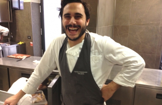 Photogallery






 
Modena’s colonnades, 186 thousand inhabitants and 3 restaurants with at least one Michelin star: Hostaria del Mare (1), Erba del Re (1) and Osteria Francescana (3 stars), our destination
 








Yellow and red tones prevail








The city still bears the signs of the May 2012 earthquake. On May 4th 2013, the day of our visit, a 3.8 magnitude earthquake was registered













By chance, Giuseppe Palmieri, maître and sommelier, appears from the grey door








Palmieri, 38, born in Matera. His first service in Francescana was on September 12th 2000








The old entrance to the restaurant, at number 24 in Via della Stella - as on the opening in 1995. It changed in September 2012: today you enter from number 22. Funnily enough, Google Maps is still set on the old entrance








The present entrance doors








Let’s start








After the latest renovations, the transit areas inside the Osteria appear as a contemporary art gallery








Mario Schifano’s world map








"Tourists", Maurizio Cattelan’s famous pigeons








Underneath the pigeons, Gavin Turk’s “Trashbag”








Three rooms, 12 tables, between 20 to 35 guests. 40% guests are Italian








Every table is illuminated by Davide Groppi’s Sampei lamp: if tables are moved, light follows








Francescana receives 150 reservations every day. But it also suffers from clients not showing up: on average, one table every week is booked but then guests don’t come








Right behind the kitchen, there’s the prêt-à-porter cellar








"In the central cellar, we only keep great vintages and larger bottles of what we consider to be great wines", Beppe Palmieri explains








1,600 wines are listed at Osteria Francescana, with a deep wine list which includes different vintages of the same wine








"A true celebration of wine "








The Ferrari coat, hanging in the cellar: Maranello is only 17 km away from Modena








Jean Todt, Michael Schumacher, Fernando Alonso: Ferrari’s “prancing horse” is at home in Via Stella








Gabrio Bini’s wines, from Pantelleria, a real fetish for Palmieri













Hanging from the ceiling, a nice selection of cured meats from Emilia








Bread made with mother yeast, the premise to a journey which will alternate great classics with very contemporary dishes








Massimo Bottura. Fifty years old last September, he is chef since 1986, the year of Trattoria del Campazzo in Nonantola. His first masters: Lidia Cristoni and Georges Cogny








He’s glowing: a few days ago his restaurant climbed, for the first time, onto the podium of the World's 50Best, a prize that is acquiring an increasing weight and authority. "The thing that makes me the happiest", he says, "is not so much the third place, but the fact that we’ve been in the highest positions for a few years now". True: 13th in 2009, 6th in 2010, 4th in 2011, 5th in 2012, 3rd in 2013








The now famous grey New Balance 993, a real emblem for the chef, friend of Jason Weis, president of the company in Massachusetts. The insole, however, is local: "In Emilia the sector is state-of-the-art", he says








"Are we ready?"








Almond granita with capers, bergamot and coffee cream 
Bottura and Palmieri’s journey across Italy starts from the bottom. And sails off from the Sicilian inland, with a classic granita which in Modena crumbles Adria-style, the wall that divides sweet from savoury, using the picklock of bitterness: Pantelleria capers, wild oregano but also bergamot, a coffee concentrate and vanilla scented salt. To pair with the first part of the meal, Sorriso di Cielo malvasia dei colli piacentini








Mediterranean Macaroon 
Next to the granita, two peculiar macaroons: the first is made with minced anchovies and sardines, the second with oysters and seaweeds. This is a classic scheme in Bottura’scuisine: his ironic turning the order of the dishes, from starter to dessert, upside down, and using popular raw materials instead of ingredients that are emblematic of élite cuisine. «While feet are sinking in the ground, the head is free to move everywhere», is one of his most famous quotes








Tempura of freshwater aulla with carpione ice-cream
Carpione ice-cream on a tempura of freshwater aulla – these fish are similar and slightly bigger than whitebait. The tempura is made by quickly placing the cold batter in boiling oil








Bread and croissants








Grissini








Baccalà Mare Nostrum 
We move up the Tyrrhenian sea to find this salted codfish cooked at low temperature and then seasoned with a touch of Naples and the Amalfi coast, that is to say with an emulsion made with hot oil with tomato vegetal liquid, olives, the zest of Sorrento’s super lemons and some anchovy colatura. These aromas crack with the scented bread on top








40 year old Denis Bretta explains the dishes as if from a book. Once at Restaurant Fini in Modena, for the past year and a half he’s been the manager responsible for the service in the restaurant. But don’t ask Palmieri to explain his role, as he’s abolished all hierarchies: "In our restaurant there are no commis or chef de rang. At a time when titles are so abused, I prefer for us to be all colleagues. All waiters."








How to burn sardines in three days 
Another journey, another horizon, the Adriatic Sea between Romagna and Ancona. A new camouflaged expression: these are not sardines (and they aren’t burnt either) but they are small sea-rock mullet, marinated for 3 days, then seared on one side on a grill, and filled like a sandwich with some (very sweet) scampi cream, and covered with vegetable ashes, aromatic herbs and lemon zest. “I wanted to make fun of the Marche-Romagna habit of grilling everything”, the chef says, “with lemon, garlic and parsley always added later to fix everything”









Rice, between fresh and sea water 
Recalling the Po estuary with freshwater and brackish sensations. The freshwater flavours cover the surface of the oyster which prevails on the river bed. And in the end, catfish, carp, vegetable chlorophyll and carpione win once again








 
A journey to Modena: Adriatic eel, polenta, Campanine apple jelly and saba
Another fluvial odyssey, presented for the first time at Identità Milano in 2011. The Adriatic eel travels across Veneto (with the polenta cream), Mantua (the Campanine apple jelly), the countryside of Modena (with the Saba lacquering, that is to say the mother of Aceto Balsamico) and stops in the centre of Modena (blackened powdered onion, a mimesis of the town’s canals)
 








Normandy
That is to say pre-salè lamb (hanging for 20 days) with an emulsion of oyster water, fresh seaweeds and caviar. On top, a green apple granita that recalls cider. “This is our tribute to Normandy”, Bretta says, “in Modena there are no enchanted beaches or breath-taking mountain tops. From Via Stella you can’t even see the Torre Ghirlandina. What guides us is the persistant strength of ideas, woven into the culture and into memories”








Giovanni Boroni’s Genziana from Trentino. A brilliant idea by Palmieri that acts as a bridge between the two dishes, Normandy (previous picture) and Think Green (next one). This distillate plays an immediate contrast with the sea-character of the first dish: "To me, harmony is what is left after a confrontation", B.P. says. And the confrontation is followed by the thought that spurs from the following match: water is added to the Genziana and the palate surprisingly longs to gulp it all. This is the perfect vehicle for the aromas of the genziana and "gives length" to the minerality of the wild herbs. "This serves to recall water, our true source of richness". Brilliant








Think Green
Vegetal chlorophyll, asparagus tops, pea cream, mushrooms, truffle, flowers, aromatic herbs and Parmigiano Reggiano curd. The idea of this dish came after observing the biological cycle of grazing cows, 4 seasons that sum up all of life. “This is what the cow eats, and what it returns to us, thanks to an extraordinary milk”, Bottura adds








Five ages of Parmigiano Reggiano 
A great classic from 1996, "when the textures in fact were 3", Palmieri points out. Today they are 5: 4 month ageing cream, 30 month demi-soufflè, 36 month mousse, 40 month crispy wafer, on top, “air” of 50 month Parmesan. (photo by Le Saucier)








A compression of pasta and beans 
Another great classic, this is a journey across Bottura’s experiences in the kitchen: Creme royal with pork rind, beans and foie gras (French tradition), rosemary air (the Spanish vanguard) and Parmesan crust (the Emilian essence) used instead of pasta. “This is a dish based on evolution, not revolution. I compressed my grandmother between Alain Ducasse and Ferran Adrià”








Snails under the grapevines 
Snails, aromatic chlorophyll on a bed of wild vegetables and herbs, with mushrooms, truffle and bulbs. After the cow’s life cycle, here comes that of the snail. "Once again, we’re chewing the territory: the best snails slither in the vineyards, among mineral, sapid and acid aromas"








A Frenchman’s dream of making pasta like an Italian 
Or, Ravioli with leeks, foie gras and truffle. We covered this in detail in Identità di Pasta issue number 27








Damijan Podversic’s Ribolla Gialla, a great wine by a wine producer from Gorizia inspired by Josko Gravner. It will support the following dish, without concealing it








A sharp knife is only served now. Another sign of the “allergy” to lengthy chewing that characterises most of contemporary high cuisine








Pigeon hunt 
And over to Bretta: "This is served in a balsamic sauce made with beetroots, which recalls blood. The salad is made with fake leaves, made by cutting out some tubers using some small stamps. These are then compressed in a vacuum with different types of vinegar. The horseradish is grated a few seconds before service, to give some velocity to the pigeon". Irony wins, since "pigeons are not hunted". The bird supplier is Franco Cazzamali from Cremona








Before the dessert, a trip to the restroom: vegetal notes prevail here too








A visit to the kitchen: capon stock








The chef watches over everything, even on the loud music wired wireless from the ceiling. When we get inside, Rod Stewart is screaming "Do you think I'm sexy?"








Meanwhile, the sauces are prepared for the evening service. There’s no break between lunch and dinner. "People sometimes leave at 5 pm because they come here to enjoy the experience of a lifetime", Palmieri reveals, "We work non-stop and every year is worse (or better, that is to say). Don’t ask me anything after midnight, though, because I can’t think straight"








Between dining room and kitchen, today 27 people work at Osteria Francescana. Many of them are interns: "Had I been offered an internship with Ducasse, at the time”, Bottura says, "I would have paid myself". In fact, he really took an internship at the Louis XV in Monte Carlo, in 1992








Leaves 
The journey takes us amidst the forests beds in Umbria: the real leaves change according to the season (black cabbage in winter, red and green basil in spring), they are caramelised and then worked with some chestnut and hazelnut paste, with a vin brulée reduction, chocolate and citrus fruits concentrate...








Magnum of Foie gras (before)
A foie gras terrine, vacuum cooked, covered with powdered toasted hazelnuts and chopped toasted almonds, finished with some apple Balsamic Vinegar. This is possibly Massimo Bottura’s most famous (and copied) dish. Alessandra Meldolesi, in her book "Sei. Autirotratto della cucina italiana d'avanguardia" she writes: "It’s a trompe-l’oeil starter in which a mould unmistakably used in the food industry, encloses the secret of the most exclusive delicacies, foie gras and Aceto Balsamico Tradizionale. This is snack versus high cuisine, dessert versus starter, entremets versus carne: the triple antiphrasis manages to get a smile"








Magnum of Foie Gras (after)
Ehm








Oops, a broken lemon tart 
A lemon tart with lemon zabaglione, lemongrass ice-cream, lemon confit, capers and bergamot (with the latter, we go back to where we had started from). This is the last dish of a masterly journey








Sous chef
Here are the staff. We start with Yoji Tokuyoshi, 35, from Japan, for 8 years at Osteria Francescana. He’s just back from the Postrivoro for Slow Fish








Managing orders
Takahiko Kondo, from Japan








Starters
Davide Di Fabio, 27 from Abruzzo








First courses
Michele Castelli, 28, Matera, in Modena since 5 years ago





