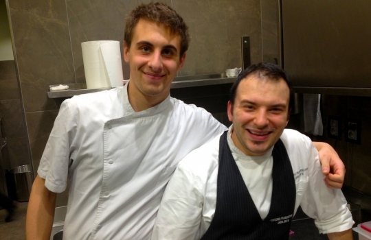 Photogallery






 
Modena’s colonnades, 186 thousand inhabitants and 3 restaurants with at least one Michelin star: Hostaria del Mare (1), Erba del Re (1) and Osteria Francescana (3 stars), our destination
 








Yellow and red tones prevail








The city still bears the signs of the May 2012 earthquake. On May 4th 2013, the day of our visit, a 3.8 magnitude earthquake was registered













By chance, Giuseppe Palmieri, maître and sommelier, appears from the grey door








Palmieri, 38, born in Matera. His first service in Francescana was on September 12th 2000








The old entrance to the restaurant, at number 24 in Via della Stella - as on the opening in 1995. It changed in September 2012: today you enter from number 22. Funnily enough, Google Maps is still set on the old entrance








The present entrance doors








Let’s start








After the latest renovations, the transit areas inside the Osteria appear as a contemporary art gallery








Mario Schifano’s world map








"Tourists", Maurizio Cattelan’s famous pigeons








Underneath the pigeons, Gavin Turk’s “Trashbag”








Three rooms, 12 tables, between 20 to 35 guests. 40% guests are Italian








Every table is illuminated by Davide Groppi’s Sampei lamp: if tables are moved, light follows








Francescana receives 150 reservations every day. But it also suffers from clients not showing up: on average, one table every week is booked but then guests don’t come








Right behind the kitchen, there’s the prêt-à-porter cellar








"In the central cellar, we only keep great vintages and larger bottles of what we consider to be great wines", Beppe Palmieri explains








1,600 wines are listed at Osteria Francescana, with a deep wine list which includes different vintages of the same wine








"A true celebration of wine "








The Ferrari coat, hanging in the cellar: Maranello is only 17 km away from Modena








Jean Todt, Michael Schumacher, Fernando Alonso: Ferrari’s “prancing horse” is at home in Via Stella








Gabrio Bini’s wines, from Pantelleria, a real fetish for Palmieri













Hanging from the ceiling, a nice selection of cured meats from Emilia








Bread made with mother yeast, the premise to a journey which will alternate great classics with very contemporary dishes








Massimo Bottura. Fifty years old last September, he is chef since 1986, the year of Trattoria del Campazzo in Nonantola. His first masters: Lidia Cristoni and Georges Cogny








He’s glowing: a few days ago his restaurant climbed, for the first time, onto the podium of the World's 50Best, a prize that is acquiring an increasing weight and authority. "The thing that makes me the happiest", he says, "is not so much the third place, but the fact that we’ve been in the highest positions for a few years now". True: 13th in 2009, 6th in 2010, 4th in 2011, 5th in 2012, 3rd in 2013








The now famous grey New Balance 993, a real emblem for the chef, friend of Jason Weis, president of the company in Massachusetts. The insole, however, is local: "In Emilia the sector is state-of-the-art", he says








"Are we ready?"








Almond granita with capers, bergamot and coffee cream 
Bottura and Palmieri’s journey across Italy starts from the bottom. And sails off from the Sicilian inland, with a classic granita which in Modena crumbles Adria-style, the wall that divides sweet from savoury, using the picklock of bitterness: Pantelleria capers, wild oregano but also bergamot, a coffee concentrate and vanilla scented salt. To pair with the first part of the meal, Sorriso di Cielo malvasia dei colli piacentini








Mediterranean Macaroon 
Next to the granita, two peculiar macaroons: the first is made with minced anchovies and sardines, the second with oysters and seaweeds. This is a classic scheme in Bottura’scuisine: his ironic turning the order of the dishes, from starter to dessert, upside down, and using popular raw materials instead of ingredients that are emblematic of élite cuisine. «While feet are sinking in the ground, the head is free to move everywhere», is one of his most famous quotes








Tempura of freshwater aulla with carpione ice-cream
Carpione ice-cream on a tempura of freshwater aulla – these fish are similar and slightly bigger than whitebait. The tempura is made by quickly placing the cold batter in boiling oil








Bread and croissants








Grissini








Baccalà Mare Nostrum 
We move up the Tyrrhenian sea to find this salted codfish cooked at low temperature and then seasoned with a touch of Naples and the Amalfi coast, that is to say with an emulsion made with hot oil with tomato vegetal liquid, olives, the zest of Sorrento’s super lemons and some anchovy colatura. These aromas crack with the scented bread on top








40 year old Denis Bretta explains the dishes as if from a book. Once at Restaurant Fini in Modena, for the past year and a half he’s been the manager responsible for the service in the restaurant. But don’t ask Palmieri to explain his role, as he’s abolished all hierarchies: "In our restaurant there are no commis or chef de rang. At a time when titles are so abused, I prefer for us to be all colleagues. All waiters."








How to burn sardines in three days 
Another journey, another horizon, the Adriatic Sea between Romagna and Ancona. A new camouflaged expression: these are not sardines (and they aren’t burnt either) but they are small sea-rock mullet, marinated for 3 days, then seared on one side on a grill, and filled like a sandwich with some (very sweet) scampi cream, and covered with vegetable ashes, aromatic herbs and lemon zest. “I wanted to make fun of the Marche-Romagna habit of grilling everything”, the chef says, “with lemon, garlic and parsley always added later to fix everything”









Rice, between fresh and sea water 
Recalling the Po estuary with freshwater and brackish sensations. The freshwater flavours cover the surface of the oyster which prevails on the river bed. And in the end, catfish, carp, vegetable chlorophyll and carpione win once again








 
A journey to Modena: Adriatic eel, polenta, Campanine apple jelly and saba
Another fluvial odyssey, presented for the first time at Identità Milano in 2011. The Adriatic eel travels across Veneto (with the polenta cream), Mantua (the Campanine apple jelly), the countryside of Modena (with the Saba lacquering, that is to say the mother of Aceto Balsamico) and stops in the centre of Modena (blackened powdered onion, a mimesis of the town’s canals)
 








Normandy
That is to say pre-salè lamb (hanging for 20 days) with an emulsion of oyster water, fresh seaweeds and caviar. On top, a green apple granita that recalls cider. “This is our tribute to Normandy”, Bretta says, “in Modena there are no enchanted beaches or breath-taking mountain tops. From Via Stella you can’t even see the Torre Ghirlandina. What guides us is the persistant strength of ideas, woven into the culture and into memories”








Giovanni Boroni’s Genziana from Trentino. A brilliant idea by Palmieri that acts as a bridge between the two dishes, Normandy (previous picture) and Think Green (next one). This distillate plays an immediate contrast with the sea-character of the first dish: "To me, harmony is what is left after a confrontation", B.P. says. And the confrontation is followed by the thought that spurs from the following match: water is added to the Genziana and the palate surprisingly longs to gulp it all. This is the perfect vehicle for the aromas of the genziana and "gives length" to the minerality of the wild herbs. "This serves to recall water, our true source of richness". Brilliant








Think Green
Vegetal chlorophyll, asparagus tops, pea cream, mushrooms, truffle, flowers, aromatic herbs and Parmigiano Reggiano curd. The idea of this dish came after observing the biological cycle of grazing cows, 4 seasons that sum up all of life. “This is what the cow eats, and what it returns to us, thanks to an extraordinary milk”, Bottura adds








Five ages of Parmigiano Reggiano 
A great classic from 1996, "when the textures in fact were 3", Palmieri points out. Today they are 5: 4 month ageing cream, 30 month demi-soufflè, 36 month mousse, 40 month crispy wafer, on top, “air” of 50 month Parmesan. (photo by Le Saucier)








A compression of pasta and beans 
Another great classic, this is a journey across Bottura’s experiences in the kitchen: Creme royal with pork rind, beans and foie gras (French tradition), rosemary air (the Spanish vanguard) and Parmesan crust (the Emilian essence) used instead of pasta. “This is a dish based on evolution, not revolution. I compressed my grandmother between Alain Ducasse and Ferran Adrià”








Snails under the grapevines 
Snails, aromatic chlorophyll on a bed of wild vegetables and herbs, with mushrooms, truffle and bulbs. After the cow’s life cycle, here comes that of the snail. "Once again, we’re chewing the territory: the best snails slither in the vineyards, among mineral, sapid and acid aromas"








A Frenchman’s dream of making pasta like an Italian 
Or, Ravioli with leeks, foie gras and truffle. We covered this in detail in Identità di Pasta issue number 27








Damijan Podversic’s Ribolla Gialla, a great wine by a wine producer from Gorizia inspired by Josko Gravner. It will support the following dish, without concealing it








A sharp knife is only served now. Another sign of the “allergy” to lengthy chewing that characterises most of contemporary high cuisine








Pigeon hunt 
And over to Bretta: "This is served in a balsamic sauce made with beetroots, which recalls blood. The salad is made with fake leaves, made by cutting out some tubers using some small stamps. These are then compressed in a vacuum with different types of vinegar. The horseradish is grated a few seconds before service, to give some velocity to the pigeon". Irony wins, since "pigeons are not hunted". The bird supplier is Franco Cazzamali from Cremona








Before the dessert, a trip to the restroom: vegetal notes prevail here too








A visit to the kitchen: capon stock








The chef watches over everything, even on the loud music wired wireless from the ceiling. When we get inside, Rod Stewart is screaming "Do you think I'm sexy?"








Meanwhile, the sauces are prepared for the evening service. There’s no break between lunch and dinner. "People sometimes leave at 5 pm because they come here to enjoy the experience of a lifetime", Palmieri reveals, "We work non-stop and every year is worse (or better, that is to say). Don’t ask me anything after midnight, though, because I can’t think straight"








Between dining room and kitchen, today 27 people work at Osteria Francescana. Many of them are interns: "Had I been offered an internship with Ducasse, at the time”, Bottura says, "I would have paid myself". In fact, he really took an internship at the Louis XV in Monte Carlo, in 1992








Leaves 
The journey takes us amidst the forests beds in Umbria: the real leaves change according to the season (black cabbage in winter, red and green basil in spring), they are caramelised and then worked with some chestnut and hazelnut paste, with a vin brulée reduction, chocolate and citrus fruits concentrate...








Magnum of Foie gras (before)
A foie gras terrine, vacuum cooked, covered with powdered toasted hazelnuts and chopped toasted almonds, finished with some apple Balsamic Vinegar. This is possibly Massimo Bottura’s most famous (and copied) dish. Alessandra Meldolesi, in her book "Sei. Autirotratto della cucina italiana d'avanguardia" she writes: "It’s a trompe-l’oeil starter in which a mould unmistakably used in the food industry, encloses the secret of the most exclusive delicacies, foie gras and Aceto Balsamico Tradizionale. This is snack versus high cuisine, dessert versus starter, entremets versus carne: the triple antiphrasis manages to get a smile"








Magnum of Foie Gras (after)
Ehm








Oops, a broken lemon tart 
A lemon tart with lemon zabaglione, lemongrass ice-cream, lemon confit, capers and bergamot (with the latter, we go back to where we had started from). This is the last dish of a masterly journey








Sous chef
Here are the staff. We start with Yoji Tokuyoshi, 35, from Japan, for 8 years at Osteria Francescana. He’s just back from the Postrivoro for Slow Fish








Managing orders
Takahiko Kondo, from Japan








Starters
Davide Di Fabio, 27 from Abruzzo








First courses
Michele Castelli, 28, Matera, in Modena since 5 years ago








Main courses
Riccardo Forapani, 27, from Cavezzo (Modena) at Osteria Francescana for the past 5 years and a half





