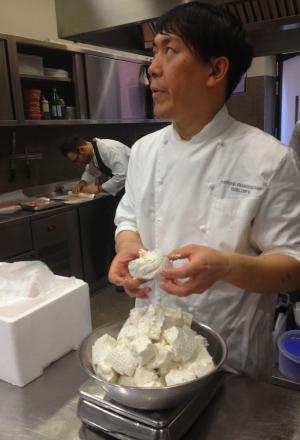 Photogallery






 
Modena’s colonnades, 186 thousand inhabitants and 3 restaurants with at least one Michelin star: Hostaria del Mare (1), Erba del Re (1) and Osteria Francescana (3 stars), our destination
 








Yellow and red tones prevail








The city still bears the signs of the May 2012 earthquake. On May 4th 2013, the day of our visit, a 3.8 magnitude earthquake was registered













By chance, Giuseppe Palmieri, maître and sommelier, appears from the grey door








Palmieri, 38, born in Matera. His first service in Francescana was on September 12th 2000








The old entrance to the restaurant, at number 24 in Via della Stella - as on the opening in 1995. It changed in September 2012: today you enter from number 22. Funnily enough, Google Maps is still set on the old entrance








The present entrance doors








Let’s start








After the latest renovations, the transit areas inside the Osteria appear as a contemporary art gallery








Mario Schifano’s world map








"Tourists", Maurizio Cattelan’s famous pigeons








Underneath the pigeons, Gavin Turk’s “Trashbag”








Three rooms, 12 tables, between 20 to 35 guests. 40% guests are Italian








Every table is illuminated by Davide Groppi’s Sampei lamp: if tables are moved, light follows








Francescana receives 150 reservations every day. But it also suffers from clients not showing up: on average, one table every week is booked but then guests don’t come








Right behind the kitchen, there’s the prêt-à-porter cellar








"In the central cellar, we only keep great vintages and larger bottles of what we consider to be great wines", Beppe Palmieri explains








1,600 wines are listed at Osteria Francescana, with a deep wine list which includes different vintages of the same wine








"A true celebration of wine "








The Ferrari coat, hanging in the cellar: Maranello is only 17 km away from Modena








Jean Todt, Michael Schumacher, Fernando Alonso: Ferrari’s “prancing horse” is at home in Via Stella








Gabrio Bini’s wines, from Pantelleria, a real fetish for Palmieri













Hanging from the ceiling, a nice selection of cured meats from Emilia








Bread made with mother yeast, the premise to a journey which will alternate great classics with very contemporary dishes








Massimo Bottura. Fifty years old last September, he is chef since 1986, the year of Trattoria del Campazzo in Nonantola. His first masters: Lidia Cristoni and Georges Cogny








He’s glowing: a few days ago his restaurant climbed, for the first time, onto the podium of the World's 50Best, a prize that is acquiring an increasing weight and authority. "The thing that makes me the happiest", he says, "is not so much the third place, but the fact that we’ve been in the highest positions for a few years now". True: 13th in 2009, 6th in 2010, 4th in 2011, 5th in 2012, 3rd in 2013








The now famous grey New Balance 993, a real emblem for the chef, friend of Jason Weis, president of the company in Massachusetts. The insole, however, is local: "In Emilia the sector is state-of-the-art", he says








"Are we ready?"








Almond granita with capers, bergamot and coffee cream 
Bottura and Palmieri’s journey across Italy starts from the bottom. And sails off from the Sicilian inland, with a classic granita which in Modena crumbles Adria-style, the wall that divides sweet from savoury, using the picklock of bitterness: Pantelleria capers, wild oregano but also bergamot, a coffee concentrate and vanilla scented salt. To pair with the first part of the meal, Sorriso di Cielo malvasia dei colli piacentini








Mediterranean Macaroon 
Next to the granita, two peculiar macaroons: the first is made with minced anchovies and sardines, the second with oysters and seaweeds. This is a classic scheme in Bottura’scuisine: his ironic turning the order of the dishes, from starter to dessert, upside down, and using popular raw materials instead of ingredients that are emblematic of élite cuisine. «While feet are sinking in the ground, the head is free to move everywhere», is one of his most famous quotes








Tempura of freshwater aulla with carpione ice-cream
Carpione ice-cream on a tempura of freshwater aulla – these fish are similar and slightly bigger than whitebait. The tempura is made by quickly placing the cold batter in boiling oil








Bread and croissants








Grissini








Baccalà Mare Nostrum 
We move up the Tyrrhenian sea to find this salted codfish cooked at low temperature and then seasoned with a touch of Naples and the Amalfi coast, that is to say with an emulsion made with hot oil with tomato vegetal liquid, olives, the zest of Sorrento’s super lemons and some anchovy colatura. These aromas crack with the scented bread on top








40 year old Denis Bretta explains the dishes as if from a book. Once at Restaurant Fini in Modena, for the past year and a half he’s been the manager responsible for the service in the restaurant. But don’t ask Palmieri to explain his role, as he’s abolished all hierarchies: "In our restaurant there are no commis or chef de rang. At a time when titles are so abused, I prefer for us to be all colleagues. All waiters."








How to burn sardines in three days 
Another journey, another horizon, the Adriatic Sea between Romagna and Ancona. A new camouflaged expression: these are not sardines (and they aren’t burnt either) but they are small sea-rock mullet, marinated for 3 days, then seared on one side on a grill, and filled like a sandwich with some (very sweet) scampi cream, and covered with vegetable ashes, aromatic herbs and lemon zest. “I wanted to make fun of the Marche-Romagna habit of grilling everything”, the chef says, “with lemon, garlic and parsley always added later to fix everything”









Rice, between fresh and sea water 
Recalling the Po estuary with freshwater and brackish sensations. The freshwater flavours cover the surface of the oyster which prevails on the river bed. And in the end, catfish, carp, vegetable chlorophyll and carpione win once again








 
A journey to Modena: Adriatic eel, polenta, Campanine apple jelly and saba
Another fluvial odyssey, presented for the first time at Identità Milano in 2011. The Adriatic eel travels across Veneto (with the polenta cream), Mantua (the Campanine apple jelly), the countryside of Modena (with the Saba lacquering, that is to say the mother of Aceto Balsamico) and stops in the centre of Modena (blackened powdered onion, a mimesis of the town’s canals)
 








Normandy
That is to say pre-salè lamb (hanging for 20 days) with an emulsion of oyster water, fresh seaweeds and caviar. On top, a green apple granita that recalls cider. “This is our tribute to Normandy”, Bretta says, “in Modena there are no enchanted beaches or breath-taking mountain tops. From Via Stella you can’t even see the Torre Ghirlandina. What guides us is the persistant strength of ideas, woven into the culture and into memories”








Giovanni Boroni’s Genziana from Trentino. A brilliant idea by Palmieri that acts as a bridge between the two dishes, Normandy (previous picture) and Think Green (next one). This distillate plays an immediate contrast with the sea-character of the first dish: "To me, harmony is what is left after a confrontation", B.P. says. And the confrontation is followed by the thought that spurs from the following match: water is added to the Genziana and the palate surprisingly longs to gulp it all. This is the perfect vehicle for the aromas of the genziana and "gives length" to the minerality of the wild herbs. "This serves to recall water, our true source of richness". Brilliant








Think Green
Vegetal chlorophyll, asparagus tops, pea cream, mushrooms, truffle, flowers, aromatic herbs and Parmigiano Reggiano curd. The idea of this dish came after observing the biological cycle of grazing cows, 4 seasons that sum up all of life. “This is what the cow eats, and what it returns to us, thanks to an extraordinary milk”, Bottura adds








Five ages of Parmigiano Reggiano 
A great classic from 1996, "when the textures in fact were 3", Palmieri points out. Today they are 5: 4 month ageing cream, 30 month demi-soufflè, 36 month mousse, 40 month crispy wafer, on top, “air” of 50 month Parmesan. (photo by Le Saucier)








A compression of pasta and beans 
Another great classic, this is a journey across Bottura’s experiences in the kitchen: Creme royal with pork rind, beans and foie gras (French tradition), rosemary air (the Spanish vanguard) and Parmesan crust (the Emilian essence) used instead of pasta. “This is a dish based on evolution, not revolution. I compressed my grandmother between Alain Ducasse and Ferran Adrià”








Snails under the grapevines 
Snails, aromatic chlorophyll on a bed of wild vegetables and herbs, with mushrooms, truffle and bulbs. After the cow’s life cycle, here comes that of the snail. "Once again, we’re chewing the territory: the best snails slither in the vineyards, among mineral, sapid and acid aromas"








A Frenchman’s dream of making pasta like an Italian 
Or, Ravioli with leeks, foie gras and truffle. We covered this in detail in Identità di Pasta issue number 27








Damijan Podversic’s Ribolla Gialla, a great wine by a wine producer from Gorizia inspired by Josko Gravner. It will support the following dish, without concealing it








A sharp knife is only served now. Another sign of the “allergy” to lengthy chewing that characterises most of contemporary high cuisine








Pigeon hunt 
And over to Bretta: "This is served in a balsamic sauce made with beetroots, which recalls blood. The salad is made with fake leaves, made by cutting out some tubers using some small stamps. These are then compressed in a vacuum with different types of vinegar. The horseradish is grated a few seconds before service, to give some velocity to the pigeon". Irony wins, since "pigeons are not hunted". The bird supplier is Franco Cazzamali from Cremona








Before the dessert, a trip to the restroom: vegetal notes prevail here too








A visit to the kitchen: capon stock








The chef watches over everything, even on the loud music wired wireless from the ceiling. When we get inside, Rod Stewart is screaming "Do you think I'm sexy?"








Meanwhile, the sauces are prepared for the evening service. There’s no break between lunch and dinner. "People sometimes leave at 5 pm because they come here to enjoy the experience of a lifetime", Palmieri reveals, "We work non-stop and every year is worse (or better, that is to say). Don’t ask me anything after midnight, though, because I can’t think straight"








Between dining room and kitchen, today 27 people work at Osteria Francescana. Many of them are interns: "Had I been offered an internship with Ducasse, at the time”, Bottura says, "I would have paid myself". In fact, he really took an internship at the Louis XV in Monte Carlo, in 1992








Leaves 
The journey takes us amidst the forests beds in Umbria: the real leaves change according to the season (black cabbage in winter, red and green basil in spring), they are caramelised and then worked with some chestnut and hazelnut paste, with a vin brulée reduction, chocolate and citrus fruits concentrate...








Magnum of Foie gras (before)
A foie gras terrine, vacuum cooked, covered with powdered toasted hazelnuts and chopped toasted almonds, finished with some apple Balsamic Vinegar. This is possibly Massimo Bottura’s most famous (and copied) dish. Alessandra Meldolesi, in her book "Sei. Autirotratto della cucina italiana d'avanguardia" she writes: "It’s a trompe-l’oeil starter in which a mould unmistakably used in the food industry, encloses the secret of the most exclusive delicacies, foie gras and Aceto Balsamico Tradizionale. This is snack versus high cuisine, dessert versus starter, entremets versus carne: the triple antiphrasis manages to get a smile"








Magnum of Foie Gras (after)
Ehm








Oops, a broken lemon tart 
A lemon tart with lemon zabaglione, lemongrass ice-cream, lemon confit, capers and bergamot (with the latter, we go back to where we had started from). This is the last dish of a masterly journey








Sous chef
Here are the staff. We start with Yoji Tokuyoshi, 35, from Japan, for 8 years at Osteria Francescana. He’s just back from the Postrivoro for Slow Fish





