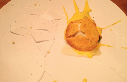 Photogallery






 
Modena’s colonnades, 186 thousand inhabitants and 3 restaurants with at least one Michelin star: Hostaria del Mare (1), Erba del Re (1) and Osteria Francescana (3 stars), our destination
 








Yellow and red tones prevail








The city still bears the signs of the May 2012 earthquake. On May 4th 2013, the day of our visit, a 3.8 magnitude earthquake was registered













By chance, Giuseppe Palmieri, maître and sommelier, appears from the grey door








Palmieri, 38, born in Matera. His first service in Francescana was on September 12th 2000








The old entrance to the restaurant, at number 24 in Via della Stella - as on the opening in 1995. It changed in September 2012: today you enter from number 22. Funnily enough, Google Maps is still set on the old entrance








The present entrance doors








Let’s start








After the latest renovations, the transit areas inside the Osteria appear as a contemporary art gallery








Mario Schifano’s world map








"Tourists", Maurizio Cattelan’s famous pigeons








Underneath the pigeons, Gavin Turk’s “Trashbag”








Three rooms, 12 tables, between 20 to 35 guests. 40% guests are Italian








Every table is illuminated by Davide Groppi’s Sampei lamp: if tables are moved, light follows








Francescana receives 150 reservations every day. But it also suffers from clients not showing up: on average, one table every week is booked but then guests don’t come








Right behind the kitchen, there’s the prêt-à-porter cellar








"In the central cellar, we only keep great vintages and larger bottles of what we consider to be great wines", Beppe Palmieri explains








1,600 wines are listed at Osteria Francescana, with a deep wine list which includes different vintages of the same wine








"A true celebration of wine "








The Ferrari coat, hanging in the cellar: Maranello is only 17 km away from Modena








Jean Todt, Michael Schumacher, Fernando Alonso: Ferrari’s “prancing horse” is at home in Via Stella








Gabrio Bini’s wines, from Pantelleria, a real fetish for Palmieri













Hanging from the ceiling, a nice selection of cured meats from Emilia








Bread made with mother yeast, the premise to a journey which will alternate great classics with very contemporary dishes








Massimo Bottura. Fifty years old last September, he is chef since 1986, the year of Trattoria del Campazzo in Nonantola. His first masters: Lidia Cristoni and Georges Cogny








He’s glowing: a few days ago his restaurant climbed, for the first time, onto the podium of the World's 50Best, a prize that is acquiring an increasing weight and authority. "The thing that makes me the happiest", he says, "is not so much the third place, but the fact that we’ve been in the highest positions for a few years now". True: 13th in 2009, 6th in 2010, 4th in 2011, 5th in 2012, 3rd in 2013








The now famous grey New Balance 993, a real emblem for the chef, friend of Jason Weis, president of the company in Massachusetts. The insole, however, is local: "In Emilia the sector is state-of-the-art", he says








"Are we ready?"








Almond granita with capers, bergamot and coffee cream 
Bottura and Palmieri’s journey across Italy starts from the bottom. And sails off from the Sicilian inland, with a classic granita which in Modena crumbles Adria-style, the wall that divides sweet from savoury, using the picklock of bitterness: Pantelleria capers, wild oregano but also bergamot, a coffee concentrate and vanilla scented salt. To pair with the first part of the meal, Sorriso di Cielo malvasia dei colli piacentini








Mediterranean Macaroon 
Next to the granita, two peculiar macaroons: the first is made with minced anchovies and sardines, the second with oysters and seaweeds. This is a classic scheme in Bottura’scuisine: his ironic turning the order of the dishes, from starter to dessert, upside down, and using popular raw materials instead of ingredients that are emblematic of élite cuisine. «While feet are sinking in the ground, the head is free to move everywhere», is one of his most famous quotes








Tempura of freshwater aulla with carpione ice-cream
Carpione ice-cream on a tempura of freshwater aulla – these fish are similar and slightly bigger than whitebait. The tempura is made by quickly placing the cold batter in boiling oil








Bread and croissants








Grissini








Baccalà Mare Nostrum 
We move up the Tyrrhenian sea to find this salted codfish cooked at low temperature and then seasoned with a touch of Naples and the Amalfi coast, that is to say with an emulsion made with hot oil with tomato vegetal liquid, olives, the zest of Sorrento’s super lemons and some anchovy colatura. These aromas crack with the scented bread on top








40 year old Denis Bretta explains the dishes as if from a book. Once at Restaurant Fini in Modena, for the past year and a half he’s been the manager responsible for the service in the restaurant. But don’t ask Palmieri to explain his role, as he’s abolished all hierarchies: "In our restaurant there are no commis or chef de rang. At a time when titles are so abused, I prefer for us to be all colleagues. All waiters."








How to burn sardines in three days 
Another journey, another horizon, the Adriatic Sea between Romagna and Ancona. A new camouflaged expression: these are not sardines (and they aren’t burnt either) but they are small sea-rock mullet, marinated for 3 days, then seared on one side on a grill, and filled like a sandwich with some (very sweet) scampi cream, and covered with vegetable ashes, aromatic herbs and lemon zest. “I wanted to make fun of the Marche-Romagna habit of grilling everything”, the chef says, “with lemon, garlic and parsley always added later to fix everything”









Rice, between fresh and sea water 
Recalling the Po estuary with freshwater and brackish sensations. The freshwater flavours cover the surface of the oyster which prevails on the river bed. And in the end, catfish, carp, vegetable chlorophyll and carpione win once again








 
A journey to Modena: Adriatic eel, polenta, Campanine apple jelly and saba
Another fluvial odyssey, presented for the first time at Identità Milano in 2011. The Adriatic eel travels across Veneto (with the polenta cream), Mantua (the Campanine apple jelly), the countryside of Modena (with the Saba lacquering, that is to say the mother of Aceto Balsamico) and stops in the centre of Modena (blackened powdered onion, a mimesis of the town’s canals)
 








Normandy
That is to say pre-salè lamb (hanging for 20 days) with an emulsion of oyster water, fresh seaweeds and caviar. On top, a green apple granita that recalls cider. “This is our tribute to Normandy”, Bretta says, “in Modena there are no enchanted beaches or breath-taking mountain tops. From Via Stella you can’t even see the Torre Ghirlandina. What guides us is the persistant strength of ideas, woven into the culture and into memories”








Giovanni Boroni’s Genziana from Trentino. A brilliant idea by Palmieri that acts as a bridge between the two dishes, Normandy (previous picture) and Think Green (next one). This distillate plays an immediate contrast with the sea-character of the first dish: "To me, harmony is what is left after a confrontation", B.P. says. And the confrontation is followed by the thought that spurs from the following match: water is added to the Genziana and the palate surprisingly longs to gulp it all. This is the perfect vehicle for the aromas of the genziana and "gives length" to the minerality of the wild herbs. "This serves to recall water, our true source of richness". Brilliant








Think Green
Vegetal chlorophyll, asparagus tops, pea cream, mushrooms, truffle, flowers, aromatic herbs and Parmigiano Reggiano curd. The idea of this dish came after observing the biological cycle of grazing cows, 4 seasons that sum up all of life. “This is what the cow eats, and what it returns to us, thanks to an extraordinary milk”, Bottura adds








Five ages of Parmigiano Reggiano 
A great classic from 1996, "when the textures in fact were 3", Palmieri points out. Today they are 5: 4 month ageing cream, 30 month demi-soufflè, 36 month mousse, 40 month crispy wafer, on top, “air” of 50 month Parmesan. (photo by Le Saucier)








A compression of pasta and beans 
Another great classic, this is a journey across Bottura’s experiences in the kitchen: Creme royal with pork rind, beans and foie gras (French tradition), rosemary air (the Spanish vanguard) and Parmesan crust (the Emilian essence) used instead of pasta. “This is a dish based on evolution, not revolution. I compressed my grandmother between Alain Ducasse and Ferran Adrià”








Snails under the grapevines 
Snails, aromatic chlorophyll on a bed of wild vegetables and herbs, with mushrooms, truffle and bulbs. After the cow’s life cycle, here comes that of the snail. "Once again, we’re chewing the territory: the best snails slither in the vineyards, among mineral, sapid and acid aromas"








A Frenchman’s dream of making pasta like an Italian 
Or, Ravioli with leeks, foie gras and truffle. We covered this in detail in Identità di Pasta issue number 27








Damijan Podversic’s Ribolla Gialla, a great wine by a wine producer from Gorizia inspired by Josko Gravner. It will support the following dish, without concealing it








A sharp knife is only served now. Another sign of the “allergy” to lengthy chewing that characterises most of contemporary high cuisine








Pigeon hunt 
And over to Bretta: "This is served in a balsamic sauce made with beetroots, which recalls blood. The salad is made with fake leaves, made by cutting out some tubers using some small stamps. These are then compressed in a vacuum with different types of vinegar. The horseradish is grated a few seconds before service, to give some velocity to the pigeon". Irony wins, since "pigeons are not hunted". The bird supplier is Franco Cazzamali from Cremona








Before the dessert, a trip to the restroom: vegetal notes prevail here too








A visit to the kitchen: capon stock








The chef watches over everything, even on the loud music wired wireless from the ceiling. When we get inside, Rod Stewart is screaming "Do you think I'm sexy?"








Meanwhile, the sauces are prepared for the evening service. There’s no break between lunch and dinner. "People sometimes leave at 5 pm because they come here to enjoy the experience of a lifetime", Palmieri reveals, "We work non-stop and every year is worse (or better, that is to say). Don’t ask me anything after midnight, though, because I can’t think straight"








Between dining room and kitchen, today 27 people work at Osteria Francescana. Many of them are interns: "Had I been offered an internship with Ducasse, at the time”, Bottura says, "I would have paid myself". In fact, he really took an internship at the Louis XV in Monte Carlo, in 1992








Leaves 
The journey takes us amidst the forests beds in Umbria: the real leaves change according to the season (black cabbage in winter, red and green basil in spring), they are caramelised and then worked with some chestnut and hazelnut paste, with a vin brulée reduction, chocolate and citrus fruits concentrate...








Magnum of Foie gras (before)
A foie gras terrine, vacuum cooked, covered with powdered toasted hazelnuts and chopped toasted almonds, finished with some apple Balsamic Vinegar. This is possibly Massimo Bottura’s most famous (and copied) dish. Alessandra Meldolesi, in her book "Sei. Autirotratto della cucina italiana d'avanguardia" she writes: "It’s a trompe-l’oeil starter in which a mould unmistakably used in the food industry, encloses the secret of the most exclusive delicacies, foie gras and Aceto Balsamico Tradizionale. This is snack versus high cuisine, dessert versus starter, entremets versus carne: the triple antiphrasis manages to get a smile"








Magnum of Foie Gras (after)
Ehm





