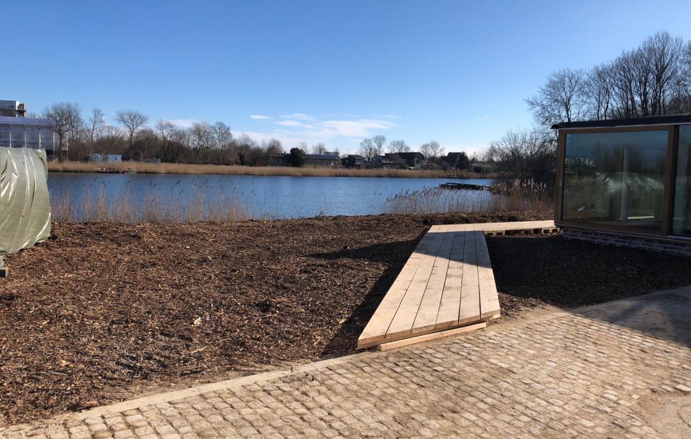 Photogallery






Noma 2.0 is in Christianshavn, the same neighbourhood as the first Noma. They’re 1.5 km apart, a 15 minutes’ walk. This picture shows the distance: to the right, there’s the warehouse of the old location (in Strandgade 93), to the left the smokestacks of Amager Bakke, the futuristic incinerator below which stands the new Noma (in Refshalevej 96)









Weather permitting, you can have a peaceful walk between the previous Noma to today’s Noma 









The new Noma is on an isthmus surrounded by canals. In the future they also want to reclaim some small parts for hydroponic farming









Bucolic scene with incinerator









Bikes left outside Noma. It’s the favourite means of transport among employees and interns









The long path taking you to the restaurant. The fence on the left shows how works are still in progress









On the two sides of the path there are the two new sections of the "Noma village", each with its specialty: grill, hot dishes, snacks, fermentations... In one month’s time, behind the fence we’ll have greenhouses, the test kitchen and the bread making area









To the left, before arriving at the restaurant, the future test kitchen. This will be run by Danish Mette Søberg with Riccardo Canella. "My first challenge?", reveals the latter, for a long time sous chef here, "is to work on the extraction of essential oils" 









The future Test Kitchen






