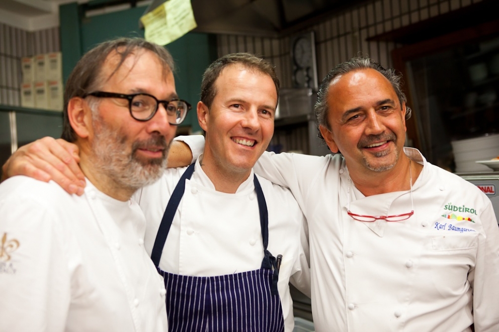 Photogallery






MAYA CALENDAR – All the 2015 communication for I Tigli will enjoy an illustration that Gianluca Biscalchin drew for the purpose: a Maya calendar representing the seasons and the ingredients Padoan usually uses








THE FIRST PIZZA – A contemporary take on the classic Margherita. This is the pizza he prepared for his first clients: «They were my neighbours, in 1994». Margherita was "classic", but Padoan-like: with fresh tomato and buffalo milk mozzarella, warmed on the side and left to drip








TECHNOLOGY OR NOT - «There’s no technology that can help if, when you cook, you do not feel the pleasure of an artisanal work, which does not allow for distraction»








HIS DAUGHTER GAIA - In 1999 Gaia, Simone’s daughter, was born, a key year as on that same year he starts to desire a professional change and a new identity 









RESEARCH – In 2000 Simone starts to analyse his first intuitions into detail. Four years of research on raw materials, cooking and, of course, making bread with mother yeast. This is when his pizza in eight slices was born 








ORIGINS AND TRADITION – Still, Padoan is very tied to his origins, as demonstrated by his choice of staying in San Bonifacio, and he’s convinced that only by remaining authentic and coherent one can let his star shine








IDENTITA' GOLOSE (1) - Padoan and I Tigli conquer more and more attention in the Italian gastronomic scene, including that of Paolo Marchi, creator of Identità Golose, who in 2008 starts to invite Simone to the congress (in the photo, the two are on the stage of Identità di Libertà, in San Marino in 2011)








THE “NEW” I TIGLI – Another turning point arrives in 2012, in particular during the three summer months, those that Padoan needed to renovate the restaurant








the old Tigli...








...and the new one








IDENTITA' GOLOSE (2) - Padoan on the stage of Identità Milano 2014, with Francesca Barberini









«THE PIZZAS I HOLD DEAREST»– Certainly the one with Burrata and prosciutto San Daniele “riserva 18 mesi”. He says: «The idea came during a motorbike tour with some friends, in 1995. We were in Tuscany, we were hungry, we went inside a shop and asked for a sandwich. The lady prepared one with burrata and prosciutto ham. Fabulous» (photo Passione Gourmet)








«LE PIZZE CUI SONO PIU AFFEZIONATO» (2) - La pizza Tagliata di tonno pinna gialla del Mediterraneo su cipolla di Tropea marinata al balsamico, «una rivisitazione della "tonno e cipolle" che si trova ovunque, col tonno in scatole e la cipolla che arriva da chissà dove. La mia versione fu un successo clamoroso, compravamo un tonno da 50-60 chili ogni settimana, a fine estate facevo scorta di cipolle per tutto l'inverno». Rapida marinatura nell'aceto, il tonno appena scottato, sale Maldon... Ora la pizza non è più in carta, per ragioni etiche













REFERENCE CHEFS - «Those I respect the most? Master Corrado Assenza (in the photo with him). Then Massimiliano Alajmo, a genius. The Portinari brothers of La Peca, Lionello Cera. And Antonio Dal Lago of Casin del Gamba. I also admire Pier Giorgio Parini...»






