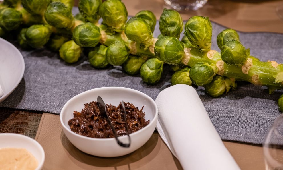 An emblem of Belgian cuisine, Brussels sprouts in the appetizer served at Bon Bon, the two-Michelin star restaurant of Christophe Hardiquest, the chef and patron who announced he will close for good on the 30th of June in view of new projects. In the dish in the photo, the Brussels sprouts end up in a mini crepe with pulled oxtail and smoked mustard. All the photos are from EquinoxLightPhoto
