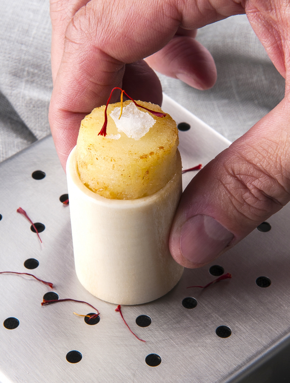 Photogallery






Mario Cornali, Collina, Almenno San Bartolomeo (Bergamo)

Stewed snails from Almenno, fumet of powdered corn from Prato – This dish is the consequence of the meeting with Andrea Togni, a young snail breeder from Almenno. I was inspired by the fact that I had an organic snail farm only two kilometres from home









Antonio Cuomo, Hostaria del Relais San Lorenzo, Bergamo

Dreaming… Cesar salad – We’ve rebuilt a great classic by changing all its textures, with water of Parmigiano, iceberg salad ice cream and confit tomato mousse









Giuliano Pellegrini, Lio Pellegrini, Bergamo

Salad with tripe, tuna, fried polenta, cucumber and white beans from Soragna – Tripe is a dish I wanted to change because I always had a good memory of it. My grandmother Alice made an excellent tripe stew...









Antonio Borruso, Umami, Bormio (Sondrio)

Neve al sole [Snow in the sun] – A dessert uniting saffron, litchi and a white chocolate mousse









Enrico and Roberto Cerea, Da Vittorio, Brusaporto (Bergamo)

Steamed king crab with hazelnut praliné and bottarga – An intriguing and delicious dish, where the white and reddish meat, firm and as sweet as honey, is finely matched by the sapidity of bottarga, much rougher and stronger. All this paired with the fattiness and crispiness of the best hazelnut in the world, the tonda gentile from Cortemilia









Nadia and Giovanni Santini, Dal Pescatore, Canneto sull'Oglio (Mantua)

Mountain potato cream with poached eggs, tuna bottarga, asetra royal caviar and capers – A great dish from Dal Pescatore’s tradition yet conceived and prepared by the new generation in the kitchen, that is to say by Giovanni Santini – photo by Culinaire Saisonnier-Dirk Kerstens









Enrico Bartolini, Devero, Cavenago di Brianza (Monza Brianza)

Risotto Arlecchino – Sauce below, rice on top. A return to the Baroque with a modern interpretation









Daniel Facen, Anteprima, Chiuduno (Bergamo)

Tuna salad with sour egg, purple potatoes and olive oil – It’s like a Salad Niçoise in which the tuna is seared and then cooled in water and ice. The purple potatoes have different textures, in pieces, as a small purée and dehydrated. The tomatoes are confit, the French beans are cooked with ultrasounds, the egg in vinegar and the oil is in a sugar capsule, with anchovies from the Cantabrian Sea






