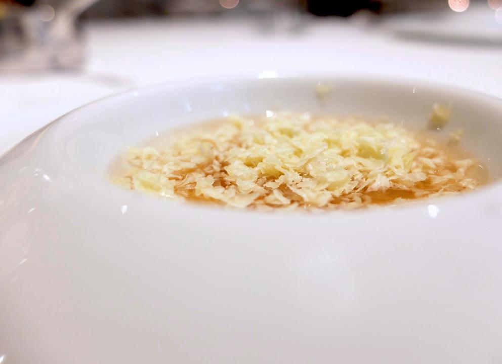 Photogallery






Water, oil, lemon and liquorice: purity. «I use it to clean the palate before the tasting. Water is energy, liquorice is synergic strength, lemon is my emblem, oil [chilled at -40°C] is my homeland»









Italy is also about bread. Taglienti makes it himself, with a 200-year-old mother yeast. On the small plate, at least two delicious types: whole wheat bread, to the right, and schiacciata with herbs and courgette flowers and dehydrated citrus fruits









A dish that, within this new tasting menu, represents something different, that is to say a hint to what the chef has done so far: Bianco e nero di seppia was born in 2009: «The input was a dish of spaghetti with squid ink I had on the beach in Sicily». Under the squid, pressed as if it were pasta, eight types of citrus fruits and panna cotta with sea urchins. Extracts, fonds and jus are increasingly essential in the cuisine of Taglienti. Through them, he channels the essence of flavour: «We always have 12 sauces in the kitchen: fonds of every possible meat, 6 juices from every citrus fruit, plus extracts». The photo shows a previous dinner we had. The author is Tanio Liotta









«I asked myself, why not serve saltimbocca alla romana?». Here it is: raw Piedmontese meat, culatello, butter emulsified with a little flour, thus adding a classic saltimbocca element, then an extract of sage and white wine – the sage is previously micro-fermented close to the stove. «In France cuisine is only about fine dining. In Italy, cuisine comprises everything». Taglienti uses the word vision for this dish









Fat goose liver from Mortara wrapped in steamed cabbage, warm oyster cream and casseoula sauce: the expression of a territory. «This is my idea of casseoula, which we cook in a classic way, and then extract so as to make a sauce». The cabbage recalls caponet or lattuga ripiena alla ligure (served with tocco, a thick meat broth which we’ll mention later too), but has fat liver too. A fantastic dish









Traditional Lasagne Bolognese: (new) avant-garde. A very thin dough, with the ragù simmering for six hours









Frittura di pesce morone al salmoriglio: heritage. «Here’s salmoriglio [not in the photo] an ancient Sicilian and Calabrian seasoning that is more and more forgotten and was one used for chargrilled fish» (olive oil, garlic, oregano, lemon juice, basil, fresh hot green chilli pepper). The batter is made with beer and encloses the fried fish as well as a sauce that is halfway between Provencal anchoiade, with anchovies, and Ligurian tapenade, with olives. Then, also fried in batter, a leaf of basil from the south, «because it’s large, while the basil from Prà in Liguria has small leaves» and then bergamot, Moroccan preserved lemon, olives form Arma di Taggia. Very good









Quintessenza di un tocco genovese: culinary memories. We’ve already mentioned tocco: it’s a sauce based on the very slow cooking of vegetables, tomatoes, mushrooms, bone marrow and then the meat you add so it releases its juices and flavours, and is served separately as a main course. Tocco is a concentrate of aromas that stays in the background. It’s a seasoning, usually, but Taglienti serves it by itself. An elegant blast of flavour









Artichoke cake: evolution. Taglienti adds an idea of tarte tatin to a classic. And a touch of Cynar. A dish halfway between savoury and sweet









Cappuccino of mushrooms with liver pudding: Italian classicism. This sweet is a small masterpiece: liver royale, black cherries, mushroom cappuccino, bay leaves, black pepper and vermouth. Extremely good, complex, and elegant









He also serves the previous dish in a less sweet version, as an entrée. We tasted it during a dinner a few months ago, when we took the following photos, which show the differences with the new road Taglienti has now taken. In this case, Mushrooms and veal liver royale. Tanio Liotta is the author of all the photos






