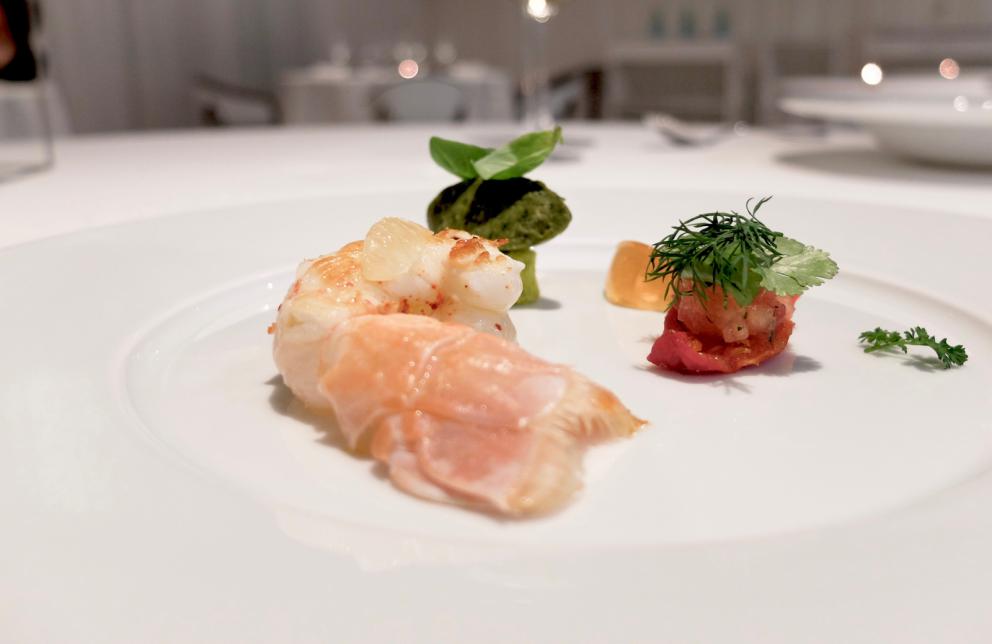 Photogallery






Water, oil, lemon and liquorice: purity. «I use it to clean the palate before the tasting. Water is energy, liquorice is synergic strength, lemon is my emblem, oil [chilled at -40°C] is my homeland»









Italy is also about bread. Taglienti makes it himself, with a 200-year-old mother yeast. On the small plate, at least two delicious types: whole wheat bread, to the right, and schiacciata with herbs and courgette flowers and dehydrated citrus fruits









A dish that, within this new tasting menu, represents something different, that is to say a hint to what the chef has done so far: Bianco e nero di seppia was born in 2009: «The input was a dish of spaghetti with squid ink I had on the beach in Sicily». Under the squid, pressed as if it were pasta, eight types of citrus fruits and panna cotta with sea urchins. Extracts, fonds and jus are increasingly essential in the cuisine of Taglienti. Through them, he channels the essence of flavour: «We always have 12 sauces in the kitchen: fonds of every possible meat, 6 juices from every citrus fruit, plus extracts». The photo shows a previous dinner we had. The author is Tanio Liotta









«I asked myself, why not serve saltimbocca alla romana?». Here it is: raw Piedmontese meat, culatello, butter emulsified with a little flour, thus adding a classic saltimbocca element, then an extract of sage and white wine – the sage is previously micro-fermented close to the stove. «In France cuisine is only about fine dining. In Italy, cuisine comprises everything». Taglienti uses the word vision for this dish









Fat goose liver from Mortara wrapped in steamed cabbage, warm oyster cream and casseoula sauce: the expression of a territory. «This is my idea of casseoula, which we cook in a classic way, and then extract so as to make a sauce». The cabbage recalls caponet or lattuga ripiena alla ligure (served with tocco, a thick meat broth which we’ll mention later too), but has fat liver too. A fantastic dish









Traditional Lasagne Bolognese: (new) avant-garde. A very thin dough, with the ragù simmering for six hours









Frittura di pesce morone al salmoriglio: heritage. «Here’s salmoriglio [not in the photo] an ancient Sicilian and Calabrian seasoning that is more and more forgotten and was one used for chargrilled fish» (olive oil, garlic, oregano, lemon juice, basil, fresh hot green chilli pepper). The batter is made with beer and encloses the fried fish as well as a sauce that is halfway between Provencal anchoiade, with anchovies, and Ligurian tapenade, with olives. Then, also fried in batter, a leaf of basil from the south, «because it’s large, while the basil from Prà in Liguria has small leaves» and then bergamot, Moroccan preserved lemon, olives form Arma di Taggia. Very good









Quintessenza di un tocco genovese: culinary memories. We’ve already mentioned tocco: it’s a sauce based on the very slow cooking of vegetables, tomatoes, mushrooms, bone marrow and then the meat you add so it releases its juices and flavours, and is served separately as a main course. Tocco is a concentrate of aromas that stays in the background. It’s a seasoning, usually, but Taglienti serves it by itself. An elegant blast of flavour









Artichoke cake: evolution. Taglienti adds an idea of tarte tatin to a classic. And a touch of Cynar. A dish halfway between savoury and sweet









Cappuccino of mushrooms with liver pudding: Italian classicism. This sweet is a small masterpiece: liver royale, black cherries, mushroom cappuccino, bay leaves, black pepper and vermouth. Extremely good, complex, and elegant









He also serves the previous dish in a less sweet version, as an entrée. We tasted it during a dinner a few months ago, when we took the following photos, which show the differences with the new road Taglienti has now taken. In this case, Mushrooms and veal liver royale. Tanio Liotta is the author of all the photos









We started with Water, oil, lemon and liquorice, in a slightly different version









Almond and tarragon, lovely






