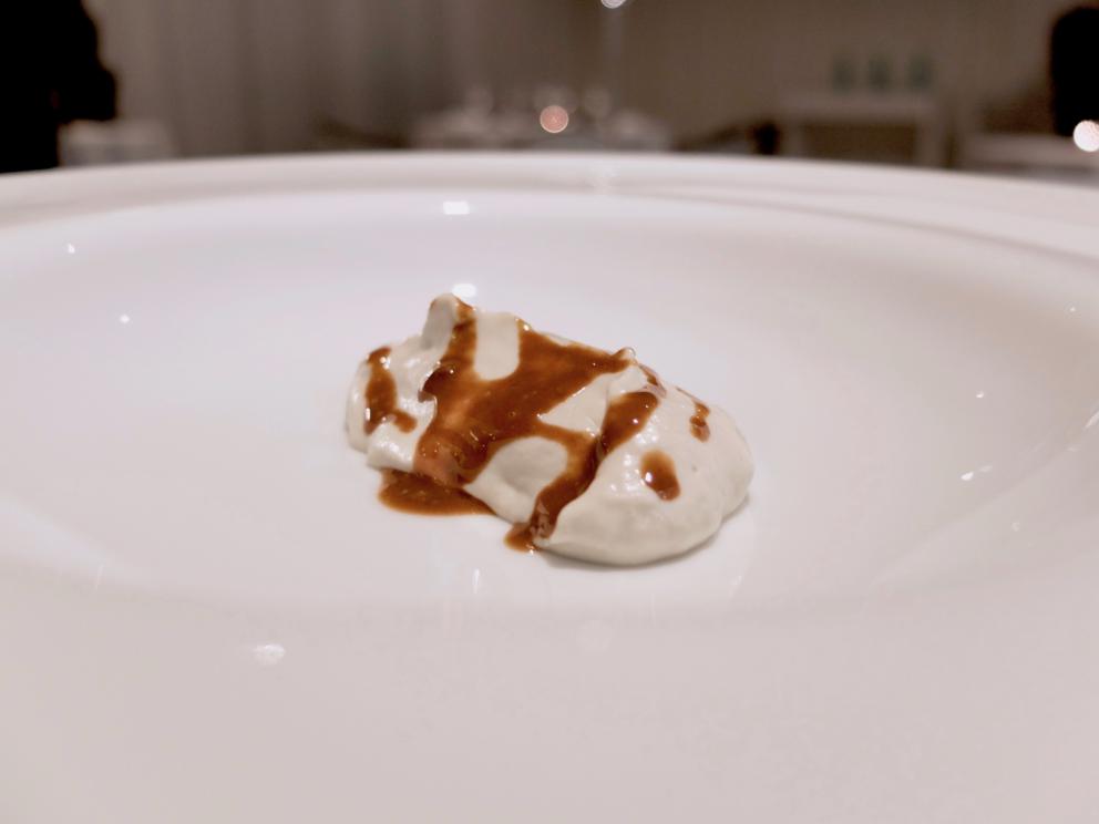 Photogallery






Water, oil, lemon and liquorice: purity. «I use it to clean the palate before the tasting. Water is energy, liquorice is synergic strength, lemon is my emblem, oil [chilled at -40°C] is my homeland»









Italy is also about bread. Taglienti makes it himself, with a 200-year-old mother yeast. On the small plate, at least two delicious types: whole wheat bread, to the right, and schiacciata with herbs and courgette flowers and dehydrated citrus fruits









A dish that, within this new tasting menu, represents something different, that is to say a hint to what the chef has done so far: Bianco e nero di seppia was born in 2009: «The input was a dish of spaghetti with squid ink I had on the beach in Sicily». Under the squid, pressed as if it were pasta, eight types of citrus fruits and panna cotta with sea urchins. Extracts, fonds and jus are increasingly essential in the cuisine of Taglienti. Through them, he channels the essence of flavour: «We always have 12 sauces in the kitchen: fonds of every possible meat, 6 juices from every citrus fruit, plus extracts». The photo shows a previous dinner we had. The author is Tanio Liotta









«I asked myself, why not serve saltimbocca alla romana?». Here it is: raw Piedmontese meat, culatello, butter emulsified with a little flour, thus adding a classic saltimbocca element, then an extract of sage and white wine – the sage is previously micro-fermented close to the stove. «In France cuisine is only about fine dining. In Italy, cuisine comprises everything». Taglienti uses the word vision for this dish









Fat goose liver from Mortara wrapped in steamed cabbage, warm oyster cream and casseoula sauce: the expression of a territory. «This is my idea of casseoula, which we cook in a classic way, and then extract so as to make a sauce». The cabbage recalls caponet or lattuga ripiena alla ligure (served with tocco, a thick meat broth which we’ll mention later too), but has fat liver too. A fantastic dish









Traditional Lasagne Bolognese: (new) avant-garde. A very thin dough, with the ragù simmering for six hours









Frittura di pesce morone al salmoriglio: heritage. «Here’s salmoriglio [not in the photo] an ancient Sicilian and Calabrian seasoning that is more and more forgotten and was one used for chargrilled fish» (olive oil, garlic, oregano, lemon juice, basil, fresh hot green chilli pepper). The batter is made with beer and encloses the fried fish as well as a sauce that is halfway between Provencal anchoiade, with anchovies, and Ligurian tapenade, with olives. Then, also fried in batter, a leaf of basil from the south, «because it’s large, while the basil from Prà in Liguria has small leaves» and then bergamot, Moroccan preserved lemon, olives form Arma di Taggia. Very good









Quintessenza di un tocco genovese: culinary memories. We’ve already mentioned tocco: it’s a sauce based on the very slow cooking of vegetables, tomatoes, mushrooms, bone marrow and then the meat you add so it releases its juices and flavours, and is served separately as a main course. Tocco is a concentrate of aromas that stays in the background. It’s a seasoning, usually, but Taglienti serves it by itself. An elegant blast of flavour









Artichoke cake: evolution. Taglienti adds an idea of tarte tatin to a classic. And a touch of Cynar. A dish halfway between savoury and sweet









Cappuccino of mushrooms with liver pudding: Italian classicism. This sweet is a small masterpiece: liver royale, black cherries, mushroom cappuccino, bay leaves, black pepper and vermouth. Extremely good, complex, and elegant









He also serves the previous dish in a less sweet version, as an entrée. We tasted it during a dinner a few months ago, when we took the following photos, which show the differences with the new road Taglienti has now taken. In this case, Mushrooms and veal liver royale. Tanio Liotta is the author of all the photos









We started with Water, oil, lemon and liquorice, in a slightly different version









Almond and tarragon, lovely









Lightly seared scampi from Liguria, chopped tomatoes in Vierge sauce and Genovese biscuit with basil from Prà






