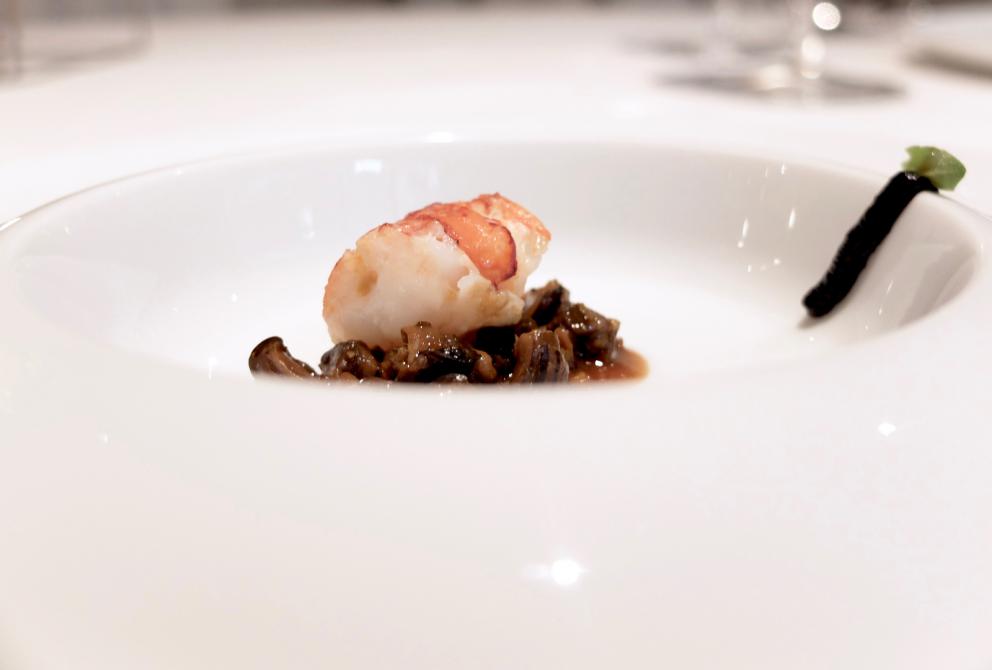 Photogallery






Water, oil, lemon and liquorice: purity. «I use it to clean the palate before the tasting. Water is energy, liquorice is synergic strength, lemon is my emblem, oil [chilled at -40°C] is my homeland»









Italy is also about bread. Taglienti makes it himself, with a 200-year-old mother yeast. On the small plate, at least two delicious types: whole wheat bread, to the right, and schiacciata with herbs and courgette flowers and dehydrated citrus fruits









A dish that, within this new tasting menu, represents something different, that is to say a hint to what the chef has done so far: Bianco e nero di seppia was born in 2009: «The input was a dish of spaghetti with squid ink I had on the beach in Sicily». Under the squid, pressed as if it were pasta, eight types of citrus fruits and panna cotta with sea urchins. Extracts, fonds and jus are increasingly essential in the cuisine of Taglienti. Through them, he channels the essence of flavour: «We always have 12 sauces in the kitchen: fonds of every possible meat, 6 juices from every citrus fruit, plus extracts». The photo shows a previous dinner we had. The author is Tanio Liotta









«I asked myself, why not serve saltimbocca alla romana?». Here it is: raw Piedmontese meat, culatello, butter emulsified with a little flour, thus adding a classic saltimbocca element, then an extract of sage and white wine – the sage is previously micro-fermented close to the stove. «In France cuisine is only about fine dining. In Italy, cuisine comprises everything». Taglienti uses the word vision for this dish









Fat goose liver from Mortara wrapped in steamed cabbage, warm oyster cream and casseoula sauce: the expression of a territory. «This is my idea of casseoula, which we cook in a classic way, and then extract so as to make a sauce». The cabbage recalls caponet or lattuga ripiena alla ligure (served with tocco, a thick meat broth which we’ll mention later too), but has fat liver too. A fantastic dish









Traditional Lasagne Bolognese: (new) avant-garde. A very thin dough, with the ragù simmering for six hours









Frittura di pesce morone al salmoriglio: heritage. «Here’s salmoriglio [not in the photo] an ancient Sicilian and Calabrian seasoning that is more and more forgotten and was one used for chargrilled fish» (olive oil, garlic, oregano, lemon juice, basil, fresh hot green chilli pepper). The batter is made with beer and encloses the fried fish as well as a sauce that is halfway between Provencal anchoiade, with anchovies, and Ligurian tapenade, with olives. Then, also fried in batter, a leaf of basil from the south, «because it’s large, while the basil from Prà in Liguria has small leaves» and then bergamot, Moroccan preserved lemon, olives form Arma di Taggia. Very good









Quintessenza di un tocco genovese: culinary memories. We’ve already mentioned tocco: it’s a sauce based on the very slow cooking of vegetables, tomatoes, mushrooms, bone marrow and then the meat you add so it releases its juices and flavours, and is served separately as a main course. Tocco is a concentrate of aromas that stays in the background. It’s a seasoning, usually, but Taglienti serves it by itself. An elegant blast of flavour









Artichoke cake: evolution. Taglienti adds an idea of tarte tatin to a classic. And a touch of Cynar. A dish halfway between savoury and sweet









Cappuccino of mushrooms with liver pudding: Italian classicism. This sweet is a small masterpiece: liver royale, black cherries, mushroom cappuccino, bay leaves, black pepper and vermouth. Extremely good, complex, and elegant









He also serves the previous dish in a less sweet version, as an entrée. We tasted it during a dinner a few months ago, when we took the following photos, which show the differences with the new road Taglienti has now taken. In this case, Mushrooms and veal liver royale. Tanio Liotta is the author of all the photos









We started with Water, oil, lemon and liquorice, in a slightly different version









Almond and tarragon, lovely









Lightly seared scampi from Liguria, chopped tomatoes in Vierge sauce and Genovese biscuit with basil from Prà









Oyster and hazelnut, a masterpiece









Eel and turnip tops 






