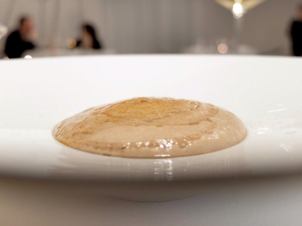 Photogallery






Water, oil, lemon and liquorice: purity. «I use it to clean the palate before the tasting. Water is energy, liquorice is synergic strength, lemon is my emblem, oil [chilled at -40°C] is my homeland»









Italy is also about bread. Taglienti makes it himself, with a 200-year-old mother yeast. On the small plate, at least two delicious types: whole wheat bread, to the right, and schiacciata with herbs and courgette flowers and dehydrated citrus fruits









A dish that, within this new tasting menu, represents something different, that is to say a hint to what the chef has done so far: Bianco e nero di seppia was born in 2009: «The input was a dish of spaghetti with squid ink I had on the beach in Sicily». Under the squid, pressed as if it were pasta, eight types of citrus fruits and panna cotta with sea urchins. Extracts, fonds and jus are increasingly essential in the cuisine of Taglienti. Through them, he channels the essence of flavour: «We always have 12 sauces in the kitchen: fonds of every possible meat, 6 juices from every citrus fruit, plus extracts». The photo shows a previous dinner we had. The author is Tanio Liotta









«I asked myself, why not serve saltimbocca alla romana?». Here it is: raw Piedmontese meat, culatello, butter emulsified with a little flour, thus adding a classic saltimbocca element, then an extract of sage and white wine – the sage is previously micro-fermented close to the stove. «In France cuisine is only about fine dining. In Italy, cuisine comprises everything». Taglienti uses the word vision for this dish









Fat goose liver from Mortara wrapped in steamed cabbage, warm oyster cream and casseoula sauce: the expression of a territory. «This is my idea of casseoula, which we cook in a classic way, and then extract so as to make a sauce». The cabbage recalls caponet or lattuga ripiena alla ligure (served with tocco, a thick meat broth which we’ll mention later too), but has fat liver too. A fantastic dish









Traditional Lasagne Bolognese: (new) avant-garde. A very thin dough, with the ragù simmering for six hours









Frittura di pesce morone al salmoriglio: heritage. «Here’s salmoriglio [not in the photo] an ancient Sicilian and Calabrian seasoning that is more and more forgotten and was one used for chargrilled fish» (olive oil, garlic, oregano, lemon juice, basil, fresh hot green chilli pepper). The batter is made with beer and encloses the fried fish as well as a sauce that is halfway between Provencal anchoiade, with anchovies, and Ligurian tapenade, with olives. Then, also fried in batter, a leaf of basil from the south, «because it’s large, while the basil from Prà in Liguria has small leaves» and then bergamot, Moroccan preserved lemon, olives form Arma di Taggia. Very good









Quintessenza di un tocco genovese: culinary memories. We’ve already mentioned tocco: it’s a sauce based on the very slow cooking of vegetables, tomatoes, mushrooms, bone marrow and then the meat you add so it releases its juices and flavours, and is served separately as a main course. Tocco is a concentrate of aromas that stays in the background. It’s a seasoning, usually, but Taglienti serves it by itself. An elegant blast of flavour









Artichoke cake: evolution. Taglienti adds an idea of tarte tatin to a classic. And a touch of Cynar. A dish halfway between savoury and sweet









Cappuccino of mushrooms with liver pudding: Italian classicism. This sweet is a small masterpiece: liver royale, black cherries, mushroom cappuccino, bay leaves, black pepper and vermouth. Extremely good, complex, and elegant






