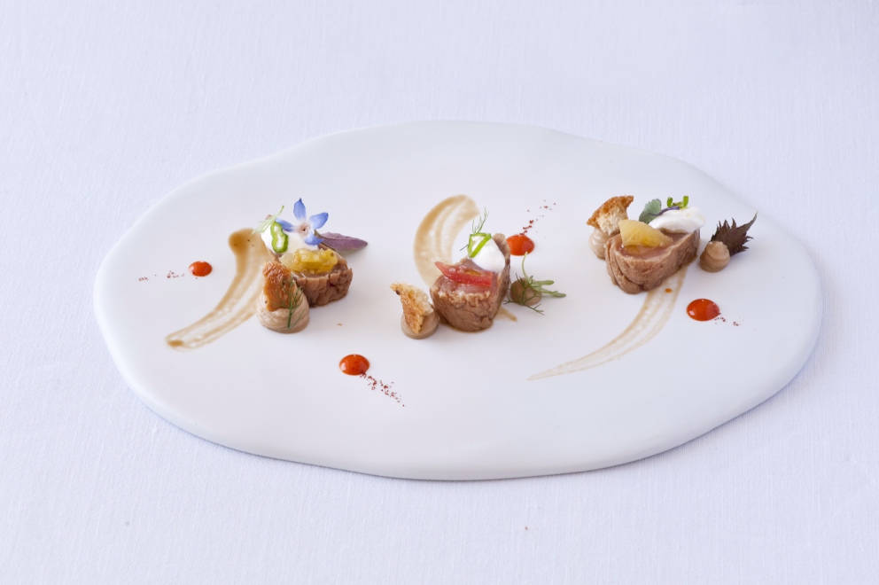 Photogallery






Iside De Cesare, La Parolina, Acquapendente (Viterbo)

Cod, garlic, oil and chilli pepper









Gianfranco Pascucci, Pascucci al Porticciolo, Fiumicino (Rome)

Eel tortelli in a broth of miso and caviar. Lake of Burano, WWF oasis: eel, myrtle and lentiscus. We’re collaborating with the WWF oases to give a "taste" to these places (photo by Andrea Di Lorenzo)









Claudio Petrolo, Claudio Petrolo, Gaeta (Latina)

Sea essence. Raw and cooked elements start an explosion with the flavour of the sea









Marco Bottega, Aminta resort, Genazzano (Rome)

Salmon, green apple and Orient spices. A meeting of sour, bitter, sweet and savoury









Rocco de Santis, Il Vistamare del Fogliano hotel, Latina

Red mullet in bread crust. A snack you can also eat with your hands, enclosing the scents of the South (I’m from Salerno): it’s like biting the sea together with onion, garlic, mint, lemon scents, raisins and pine nuts









Daniele Usai, Il Tino, Ostia (Rome)

Gnocchi with mandarin, with cod tripe and spinach. A historic dish from our menu has just returned in a current version









Gino Pesce, Acqua Pazza, Ponza (Latina)

Candele, cheese, pepper, white fish and courgettes. Created for a project we presented at Expo Milano with the goal of enhancing all the POD products of Lazio









Maurizio e Sandro Serva, La Trota, Rivodutri (Rieti)

Crayfish, roots, tubers, watercress with smoked trout and lake whitefish roe. A concentrate of flavours and lightness: roots, tubers and crayfish are steamed with aromatised water, with vegetable peels and Matcha tea. There’s no salt: the sapidity is giveb by the roe, the smokiness of the trout and the minerals in the vegetables and in the watercress, picked from our brook









Andrea Fusco, Giuda Ballerino, Rome

Venison sirloin with its jus and hibiscus, caramelised onions with blueberries and pistachio wafer. Serving a rich and lean red meat that is rarely served in this season









Cristina Bowerman, Glass Hostaria, Rome

Pasta and potatoes. Four different types of potatoes, with 4 different cooking methods, from mashed to crispy. Inspired by Bottura’s Compression of pasta and beans 









Anthony Genovese, Il Pagliaccio, Rome

Oyster, beetroot and coffee, snow of burrata. A journey across different scents, temperatures and textures









Francesco Apreda, Imàgo dell'hotel Hassler, Rome

Tandoori duck breast, cocoa earth and dried apricots. My personal take of a great classic from a continent I’m very fond of









Arcangelo Dandini, L'Arcangelo, Rome

My cipollata: zita with onion fondant with three spices. Taken from the Renaissance cipollata of Bartolomeo Scappi, the secret chef of 6 popes, who lived almost 30 years in Rome
 









Heinz Beck, La Pergola, Rome

S Campo. It’s the interpretation, with a modern take, of minestrone, made with lyophilisation. Each vegetable is cooked in the most suitable way so as to maintain its nutritional characteristics and then lyophilised. The result is 6, 7, 8 powders which are then put in the dish. The dish is served with scampi breaded with potatoes and soaked in front of the guest with a jus of this crustacean (photo by Janez Puksic)









Alba Esteve Ruiz, Marzapane, Rome

Chestnut cappeletti, raisins, smoked herring and seaweed infusion. Contrasts: the soft chestnut filling and a very persistent flavour, the smokiness and the fatness of the eel, the intense sweetness of the raisins, the sapidity of the seaweed infusion, the crispiness of the pasta...









Marco Baccanelli e Francesca Barreca, Mazzo, Rome

Roasted quails, baked tubers and roots, herb butter. The quails are served in their original shape, without deboning them. Our cuisine is moving towards a greater simplicity, and we can do so even by choosing classic yet not simple techniques









Roy Caceres, Metamorfosi, Roma

Mushrooms, flax brittle, black garlic and cream with Monviso blue cheese. In the seeming simplicity of an ingredient like mushrooms, contrasting textures give life to a dish in which their identity is surprisingly enhanced

 









Davide Del Duca, Osteria Fernanda, Rome

Snails, radish roots, Purgatorio beans, leaves and mustard seeds. A tribute to the material and primordial essence of the “earth” concept









Luciano Monosilio, Pipero al Rex, Rome

Vermicelli creamed in chicken broth, toasted spices and parmesan infusion. This recipe comes from spaghetti creamed in a very normal broth. The spices recall high mountains with the balsamic note counterbalanced by the sweet water of the parmesan. Almost like ramen









Marco Martini, Stazione di Posta, Rome

Steamed raviolo, chicken and broth of roasted potatoes. A meeting of east, west and my mother’s home









Francesco Sposito, Taverna Estia, Brusciano (Naples)

Tortellini with dandelion in a consommé of crustaceans. Introduced only recently, I’m very happy with it because it sums up the course we’ve taken









Vitantonio Lombardo, Locanda Severino, Caggiano (Salerno)

Mela Gras, that is to say mousse of chicken liver with dessert wine in a gelatine of annurca apples on a mixed leaf salad and hazelnuts from Giffoni. Creative and elegant cuisine with local products









Rosanna Marziale, Le Colonne, Caserta

Pasta with tomatoes. Paccheri from Gragnano with three types of tomatoes: San Marzano, piennolo and corbarino made with three different cooking techniques, with buffalo buttermilk









Pasquale Torrente, Al Convento, Cetara (Salerno)

'Ndunderi (ricotta gnocchi). These are pasta’s ancestors. They were born on the Amalfi Coast and are part of a project that this year, at Al Convento, will rediscover ancient local recipes









Christoph Bob, Monastero di Santa Rosa, Conca dei Marini (Salerno)

Linguine with nettle emulsion, salicornia and sea truffles









Giulio Coppola, La Galleria, Gragnano (Naples)

Spaghetti with lemon, with beef muzzle, pesto of olives, lupines and rocket salad. It says a lot about my territory and recalls the O Per e Muss, a street food recipe that people enjoy in the evenings in the South all year round









Pasquale Palamaro, Indaco del Regina Isabella, Ischia (Naples)

Sea foie gras. Cod liver prepared like the French geese one to make foie gras. Paired with cabbage, beetroot, ginger and toasted bread









Alfonso Caputo, La Taverna del Capitano, Massa Lubrense (Naples)

Seabream and prawns, figs and moka with sea urchin needles. The richness of the sea with the addition of an iodine note to enhance the taste through all the senses (in the photo, the summer version with cherry tomatoes from Vesuvius)









Salvatore Bianco, Il Comandante at Romeo hotel, Naples

Squid and bamboo with emulsion of cardamom with citrus fruits, soft potato with soy milk and black olives. It fully represents my cooking philosophy: ingredients from my homeland meet raw materials from different cultures
 









Lino Scarallo, Palazzo Petrucci, Naples

Soused red mullet with a soy reduction, couscous of Roman cabbage, papaccelle and black olives. Together with the red mullet, this recipe is based on raw materials from our traditional cuisine, with a modern take, an international interpretation inspired by the Japanese preparation of eels
 









Gianluca D'Agostino, Veritas, Naples

Roasted mackerel with fresella, tomato and goat cheese. It’s my take on fresella with tomato and tuna/anchovies









Marianna Vitale, Sud, Quarto (Naples)

Spaghettoni with artichokes, sea urchins and cinnamon. Sweet, bitter and spicy notes are matched with the aftertaste of the sea rust (as of February it will be part of a whole menu only made of pasta)









Michele Deleo, Rossellinis di Palazzo Avino, Ravello (Salerno)

Variations on pasta, cornaioli peas, gobbo prawn and sea roe. This dish was inspired by Pasta and peas, an old recipe typical of Campania, which included the use of a beaten egg to thicken everything. I used sea roe (bottarga, sea urchns and prawns) instead of bird eggs and I didn’t cook the pasta with the peas but in a seafood broth. I finally mixed everything with sweet pecorino and crushed pepper









Lorenzo Cuomo, Re Maurì at Lloyd's Baia hotel, Salerno

Spaghetti alla chitarra with oil aromatised with oranges, turnip tops, crispy calamari and sea urchins. A rhythmical pinwheel of flavours and textures









Ernesto Iaccarino, Don Alfonso, Sant'Agata sui Due Golfi (Naples)

Crispy crustacean cylinder and emulsion of its roe with soft buffalo milk mozzarella and organic vegetables from the kitchen garden in Punta Campanella. An unusual pairing of buffalo milk mozzarella and shellfish, based on the affinity between the sweet and savoury notes of both









Giovanni Sorrentino, Gerani, Santa Maria La Carità (Naples)

Tagliolino with raw and cooked white prawns, buffalo milk yogurt, baked cherry tomatoes and liquorice. It perfectly sums up my passion and my approach in cooking. My homeland looked at with the eyes of someone who’s back after a long journey









Mario Affinita, Don Geppi, Sorrento (Naples)

Calamari become scallops with a soup of potatoes with citronella. Because you always need to go beyond appearances in life









Paolo Barrale, Marennà, Sorbo Serpico (Avellino)

Linguine "Cacio&Pepe", peas and prawns. It’s a dish based on leftovers: I thicken the pasta with the caciocavallo left over from other recipes. The cheese/peas pair is traditionally very popular from Rome southwards. And the raw prawns give that extra touch, which well matches the spiciness of the cheese









Luigi Tramontano, Terrazza Bosquet at Excelsior Vittoria, Sorrento (Naples)

Seared scampi aromatised with tonka beans, with stracciatella of burrata, coconut mousse and cream of squilla mantis. The fusion of Mediterranean flavours with creative touches in search for a balance of taste. Substance and personality









Giuseppe Iannotti. Kresios, Telese Terme (Benevento)

Veal in tuna sauce. Katsuobushi broth of veal, belly of red tuna and chard. A fusion dish built on a great classic of Italian cuisine (photo by Tania Mauri)









Luciano Villani, Locanda del Borgo, Telese Terme (Benevento)

Mussels alla scapece, mussel mayonnaise and crispy seaweeds. In a way, it represents my origins from Castellammare di Stabia. A balanced dish in terms of acidity, crispiness and sapidity









Cristian Torsiello, Osteria Arbustico, Valva (Salerno)

Raviolo with celeriac, butter and sage and colatura, lemon and white truffle. It was born from my desire to make pasta filled with a vegetable that can still be perceived on the palate: it’s in the shape of a brunoise, not the usual creamy filling. It’s paired with another fruit of the earth, that is to say truffle, together with the classic butter and sage and colatura









Peppe Guida, Antica Osteria Nonna Rosa, Vico Equense (Naples)

Broken spaghetti with broccoli and chilli pepper. I thought of presenting it in a version with garlic and oil, smoked saurel, friarielli peppers and 'nduja (photo by Valentina Santonastaso)






