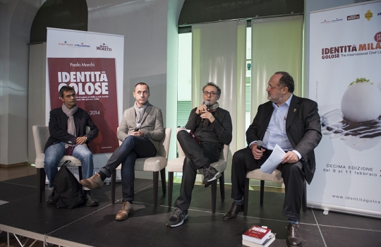 Galleria fotografica






La settima edizione della Guida Identità Golose ai ristorante d'autore in Italia e nel mondo









La sala gremita del Magna Pars Suite MIlano in via Forcella 6 a Milano








I Migliori chef per la Guida di Identità Golose 2014 sono Alessandro Negrini e Fabio Pisani de Il Luogo di Aimo e Nadia a Milano. Con loro sul palco, il sommelier Nicola Dell'Agnolo e Stefania Moroni. A premiarli Carlo Bianchi, area manager di Cavit. A destra, Paolo Marchi, curatore della Guida di Identità 2014.








Alessandro Negrini e Fabio Pisani "depositano" la loro impronta d'autore








La Migliore chef donna è Sara Preceruti de La Locanda del Notaio di Pellio Intelvi (Como), menzione speciale Sognatori del Gusto. Premia Marco Barbieri, International Relations Team di S.Pellegrino.








Sara Preceruti








Paolo Marchi con Oscar Farinetti, autore della prefazione della guida








Il Miglior chef straniero 2014 è Kobe Desramaults del ristorante In de Wulf a Heuvelland nelle Fiandre, in Belgio. Premia Serena Stefanoni de il Consorzio Grana Padano. Con loro Gabriele Zanatta (a sinistra), caporedattore della guida, e Paolo Marchi








Kobe Desramaults








Il Miglior sous chef è Alessandro Procopio del ristorante D’O di Cornaredo (Milano), chef Davide Oldani (in foto, a sinistra). È premiato da Sara Peirone, responsabile Top Gastronomy di Lavazza.








Paolo Marchi con Carlo Cracco, autore della prefazione dolce








Paolo Marchi con Massimo Bottura, autore del racconto di Modena








Il miglior chef pasticciere è Luca Sacchi del ristorante Cracco a Milano. Premia Cristina Trolli di Zafferano 3 Cuochi. Con loro, lo chef Carlo Cracco e Paolo Marchi








Luca Sacchi, Miglior Chef Pasticciere 2014








Il Premio Birra in cucina è di Daniele Usai del ristorante Il Tino di Ostia a Roma. A premiarlo per Birra Moretti, Alfredo Pratolongo, direttore Comunicazione e Affari istituzionali di Heineken Italia








Daniele Usai con il premio Caraiba e la guida








Nel corso della presentazione








La Miglior carta dei vini e distillati: Imago dell’Hotel Hassler di Roma. A ritirare il premio, il sommelier Marco Amato e lo chef Francesco Apreda. Premia Marco Ravasi, brand director Italy di Ruinart








Le firme di Marco Amato e Francesco Apreda








Il Miglior sommelier è Valerio Capriotti del ristorante Duomo di Ragusa Ibla, chef Ciccio Sultano (sul palco, a sinistra). Premia Carlo Mogolino, brand manager di Torre Rosazza








Valerio Capriotti








Il Miglior maître è Donato Marzolla, del ristorante Rossellinis del Palazzo Avino a Ravello (Salerno). Premia Tenuta Sant’Anna: in foto, Francesco Marchese, responsabile marketing e comunicazione de Le Tenute di Genagricola








Donato Marzolla








Il premio fornito, come ogni anno, da Caraiba: le porcellane Figgjio Norway
 








Sorpresa dell’anno: Beniamino Nespor ed Eugenio Roncoroni de Al Mercato di Milano. Premia Anna Maschio di Bonaventura Maschio








Eugenio Roncoroni (a sinistra) e Beniamino Nespor








La Giovane famiglia dell’anno: Mattia, Alessio con Bruna e Marcello Spadone del ristorante La Bandiera di Civitella Casanova, Pescara (a Milano c’erano Alessio e Marcello). A premiarli, Alfredo Zini, dell’Ente bilaterale nazionale del Turismo








Le firme di Alessio e Marcello Spadone








Miglior Giornalista, lo svedese Mattias Kroon (Sydsvenska Dagbladet e Mat&Vanner). Premia Anna Baccarani, ufficio marketing di Surgital. A sinistra Gabriele Zanatta e a destra Paolo Marchi








Mattias Kroon








Con Paolo Marchi, Giorgia Martone del Magna Pars Suites Milano e lo chef Fulvio Siccardi del ristorante Da Noi In





