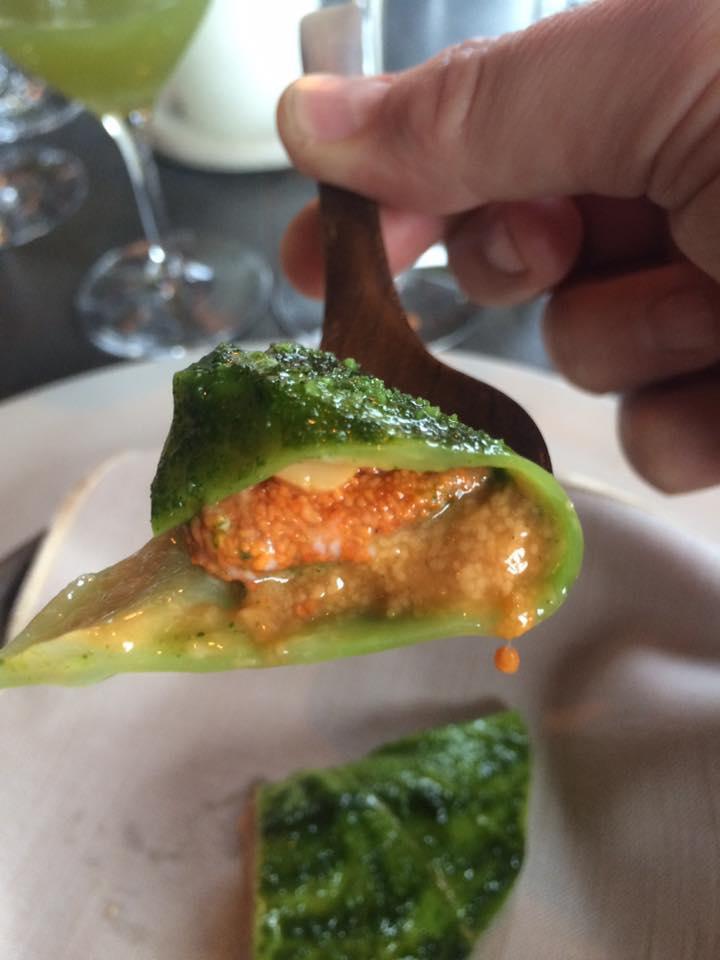 Photogallery






The traditional welcome at Noma: the chefs from the service kitchen greet the guests. In the middle, Italian Riccardo Canella, who will help us describing the last menu in detail (photo gallery by Luca Iaccarino and Gabriele Zanatta)









Warm broth of cloudberries. It’s the last welcome dish at Noma. It’s cold outside but as soon as you sit inside, you get warm thanks to this hot broth made with cloudberries enriched with rhubarb root oil. You dip a bouquet of hay, lemon thyme and mountain pine. Corroborating









Riccardo Canella brings a preview of what will follow









It’s a dish with seafood, including a huge (and alive) king crab, sea urchins and oysters









Apple of the season









Apple of the season. Once you open the shell, many small apple parisienne appear in a juice made with centrifuged, clarified apple scraps, seasoned with verbena and thyme. There’s also a purée of apples fermented in broth. The dish is finished with oxalis flowers, tagete and oil of blackcurrant wood, made by beating the blackcurrant branches with a hammer, so as to extract their essential oils. A very pleasant dish despite its complex idea.

"The first time I saw it ", added Canella, "I was struck because it reminded me of the stuffed apples they used to make at restaurant Bulesca in Selvazzano, Padua, in the early Eighties. Except in that case it was filled with rolls made with granny smith apple and prosciutto from Montagnana" 









Fresh sliced scallop. It’s a scallop taken from the fish tank and shelled a few moments before serving it. It is then sliced, brushed with a reduction of vegetable whipped butter with cucumber centrifuge juice, then reduced, and piso broth (that is to say miso with dehydrated peas).

The technique is the same used for the broth ice-clarification made famous in the Nineties by Heston Blumenthal at Fat Duck: you freeze the broth then hang a table cloth so as to obtain the “pure” part of the liquid. A trick that adds the same satisfying sensation of a meat jus to a vegetable broth. The scallop is finally dipped into a classic mussel broth. An incredible mouthful of seafood and umami









A Winter Platter. Hidden among the leaves, are four edible tastings









He sums up in just one dish 4 snacks that he might would have served separately a few years back. A fun and tasty idea. In detail:

At 6 o’clock: Pear pressed in fermented red gooseberry with fully ripe common sea buckthorn. It’s a rather tart ensemble made sweeter by piso (again miso made with dried peas) seasoned with coriander seeds (supplied by Redzepi’s historic supplier Soren Wiuff). The external thinner leaf is a peel made with chicken broth and beech leaves preserved in vinegar.

10 o'clock: crispy black currant leaf-shaped sandwich, seasoned with yogurt, kombucha, elderberry flowers and red oxalis 

12 o'clock: malt branch with nasturtium leaves, creme fraiche, salt aromatised with pine and ants

4 o'clock: black garlic leaf with salt aromatised with kelp, a Japanese seaweed 









A detail of the malt branch, with well visible ants. At Noma, the study of the aromatic contribution given by formic acid to dishes continues. And even the service acquires elegance: in the past you might have seen ants floating in a few dishes. This is no longer the case









A Tupperware from the "ant library", on the first floor at Strangade









Radish pie. It’s an emblem of the latest menus at Noma. It’s been in the menu for almost a year. In the crunchy disc on the bottom there’s kelp seaweed and a vegetable reduction made with coriander pesto. The radish roses (22, no more, no less) were pressed in beetroot juice. Another formidable tasting









Interns roll the radish roses together, on the top floor at Noma. Loud music and teamwork help making the job less alienating









Natural fermented bread of Øland wheat and hulless barley.  Øland wheat is Danish, with 83% hydration. “Nerd” bread maker Rasmus Kristensen is obsessed with it: even though it could last a week, he bakes it fresh every day for the two services (see the interview on Vice). It has a crispy yet soft crust, and it’s a great progress compared to the early bread making at the restaurant.

The salted butter is instead Norwegian Røros, according to some “the best butter in the world”. One of the most extraordinary pairings ever tasted. We asked for an encore









Cooked oyster and broccoli stems. The oyster is blanched for two minutes and placed on a shell with the edges powdered with salicornia. Between the broccoli and the oyster there are some diced stalks of sorrel. There’s a reduction with kelp seaweed, whisked with butter, thyme and “capers” made with white currants [they’re not real capers but the currants are preserved for a year in 2% salt, like capers). The sauce for the oyster is made with white gooseberries. An artwork, but less convincing than the other tastings









Sea urchin and cabbage. It’s a cabbage leaf pressed with hazelnut oil, filled with sea urchin roe and seasoned with pine vinegar, water from fermented porcini and pickled chanterelle mushrooms. On top, there’s parsley pesto and salt aromatised with pine. It’s a dish that changes greatly according to the season: compared to September, the leaves are now smaller and woodier. Two extraordinary mouthfuls, the result of a rather simple intuition






