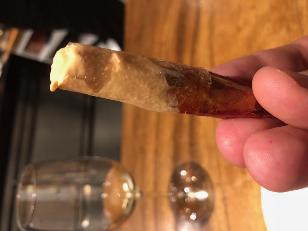 Photogallery






The sign appearing on Soi Langsuan in Bangkok, the little road where you can find restaurant Gaggan and, in front of it, the new-born Gaa, same ownership









The entrance to the restaurant, which recently got the second Michelin star. It’s open only in the evening. There are 65 people here who serve 100 clients daily, divided into two shifts (photo from themalaymailonline.com)









Gaggan’s famous emoji menu: "We first create the dish, then we sum it up with an emoji", he points out (photo from Andershusa/Instagram)









1 
Pink elderflower and watermelon
The tasting menu starts with the notes of the Foo Fighters. The entire first part of the menu is to be eaten with your hands: "This is how it works in India", he explains. First dish: a pearl among elderberry flowers and watermelon in an edible oyster shell. A debut to rinse the palate









2
Yogurt Explosion
Gaggan’s most famous dish. It’s the result of his early internship at elBulli in Roses, Catalonia. "If Ferran Adrià has had Spanish people accept a spherified olives", he says, "why shouldn’t I do the same with an emblem of India?". The spherified yogurt is made with low fat yogurt dipped in a sodium alginate









3
Lick it up. Mushroom peas
With "Lick it up", a hit from the Eighties by Kiss playing in the background, they serve this dish which you must hold with both hands and lick. The sauces, from bottom to top, in "licking order ": tomato, dehydrated mushrooms and mashed green chickpeas. On top, shaved truffle.  "Music, words, food. This is how we represent lightness"









Gaggan holds a cone






