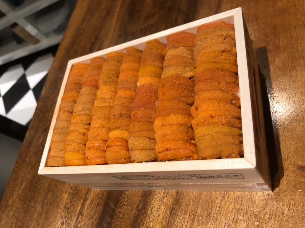 Photogallery






The sign appearing on Soi Langsuan in Bangkok, the little road where you can find restaurant Gaggan and, in front of it, the new-born Gaa, same ownership









The entrance to the restaurant, which recently got the second Michelin star. It’s open only in the evening. There are 65 people here who serve 100 clients daily, divided into two shifts (photo from themalaymailonline.com)









Gaggan’s famous emoji menu: "We first create the dish, then we sum it up with an emoji", he points out (photo from Andershusa/Instagram)









1 
Pink elderflower and watermelon
The tasting menu starts with the notes of the Foo Fighters. The entire first part of the menu is to be eaten with your hands: "This is how it works in India", he explains. First dish: a pearl among elderberry flowers and watermelon in an edible oyster shell. A debut to rinse the palate









2
Yogurt Explosion
Gaggan’s most famous dish. It’s the result of his early internship at elBulli in Roses, Catalonia. "If Ferran Adrià has had Spanish people accept a spherified olives", he says, "why shouldn’t I do the same with an emblem of India?". The spherified yogurt is made with low fat yogurt dipped in a sodium alginate









3
Lick it up. Mushroom peas
With "Lick it up", a hit from the Eighties by Kiss playing in the background, they serve this dish which you must hold with both hands and lick. The sauces, from bottom to top, in "licking order ": tomato, dehydrated mushrooms and mashed green chickpeas. On top, shaved truffle.  "Music, words, food. This is how we represent lightness"









Gaggan holds a cone









4
Tom Yum Kung
This is his version of Tom Yam (or Yum), a popular Thai soup. It’s a cold purée of tom yam served in crispy rice paper with a head of scampi to add flavour. It’s a sort of prawn cocktail in the shape of a cone









5
Goat brain, flower power
A cracker of goat brain ("to us Indians, it’s like foie gras", beams Gaggan) and rice flour. It is served to women first, playing with the similar sounds of flour and flower









6
Eggplant cookie
A cookie of aubergine, a sandwich the size of a coin, held together thanks to some onion chutney. "Out of 20, in Asia ingredients are usually worth 5, technique 15. With this dish I wanted to go in the opposite direction, return to Western minimalism with a universal emblem, that is to say aubergines. It’s a recent dish, which portraits the restaurant as it is now"









7
Chilly bon bon
Chilli pepper spheres. "Chocolates" filled with cumin, chilli pepper, ginger, and other spices. "In India there are four degrees of spiciness: hot, hotter, very hot and hell". The bon bon was mildly hot









8
Idly Sambar
Idly Sambar is a Tamil recipe, from the south of India: vegetable stew, tamarind and varying spices. "The world can be divided into two: those who eat rice, and those who eat bread. In this case, the base is bread made of fermented rice"









9
Banana chicken liver
"My daughter is one year and a half old. She’s difficult when it comes to eating. Give this combination to your children and they’ll be happy"









10
Fish Granola
Granola with fried seabass, walnuts and cheese cream









11
Gin tonic cucumber uni
Sea urchin cones, temaki, key lime and Indian tonic water. "This dish is the result of my trips to Japan: I went there 74 times only in the last couple of years. It has sea urchins from Hokkaido, in the north. In India we never eat raw food". The nori seaweed is made with dill






