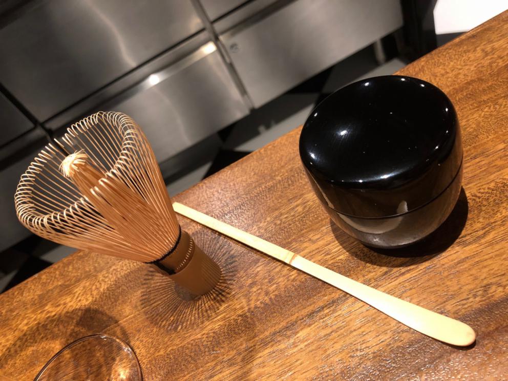 Photogallery






The sign appearing on Soi Langsuan in Bangkok, the little road where you can find restaurant Gaggan and, in front of it, the new-born Gaa, same ownership









The entrance to the restaurant, which recently got the second Michelin star. It’s open only in the evening. There are 65 people here who serve 100 clients daily, divided into two shifts (photo from themalaymailonline.com)









Gaggan’s famous emoji menu: "We first create the dish, then we sum it up with an emoji", he points out (photo from Andershusa/Instagram)









1 
Pink elderflower and watermelon
The tasting menu starts with the notes of the Foo Fighters. The entire first part of the menu is to be eaten with your hands: "This is how it works in India", he explains. First dish: a pearl among elderberry flowers and watermelon in an edible oyster shell. A debut to rinse the palate









2
Yogurt Explosion
Gaggan’s most famous dish. It’s the result of his early internship at elBulli in Roses, Catalonia. "If Ferran Adrià has had Spanish people accept a spherified olives", he says, "why shouldn’t I do the same with an emblem of India?". The spherified yogurt is made with low fat yogurt dipped in a sodium alginate









3
Lick it up. Mushroom peas
With "Lick it up", a hit from the Eighties by Kiss playing in the background, they serve this dish which you must hold with both hands and lick. The sauces, from bottom to top, in "licking order ": tomato, dehydrated mushrooms and mashed green chickpeas. On top, shaved truffle.  "Music, words, food. This is how we represent lightness"









Gaggan holds a cone









4
Tom Yum Kung
This is his version of Tom Yam (or Yum), a popular Thai soup. It’s a cold purée of tom yam served in crispy rice paper with a head of scampi to add flavour. It’s a sort of prawn cocktail in the shape of a cone









5
Goat brain, flower power
A cracker of goat brain ("to us Indians, it’s like foie gras", beams Gaggan) and rice flour. It is served to women first, playing with the similar sounds of flour and flower









6
Eggplant cookie
A cookie of aubergine, a sandwich the size of a coin, held together thanks to some onion chutney. "Out of 20, in Asia ingredients are usually worth 5, technique 15. With this dish I wanted to go in the opposite direction, return to Western minimalism with a universal emblem, that is to say aubergines. It’s a recent dish, which portraits the restaurant as it is now"









7
Chilly bon bon
Chilli pepper spheres. "Chocolates" filled with cumin, chilli pepper, ginger, and other spices. "In India there are four degrees of spiciness: hot, hotter, very hot and hell". The bon bon was mildly hot









8
Idly Sambar
Idly Sambar is a Tamil recipe, from the south of India: vegetable stew, tamarind and varying spices. "The world can be divided into two: those who eat rice, and those who eat bread. In this case, the base is bread made of fermented rice"









9
Banana chicken liver
"My daughter is one year and a half old. She’s difficult when it comes to eating. Give this combination to your children and they’ll be happy"









10
Fish Granola
Granola with fried seabass, walnuts and cheese cream









11
Gin tonic cucumber uni
Sea urchin cones, temaki, key lime and Indian tonic water. "This dish is the result of my trips to Japan: I went there 74 times only in the last couple of years. It has sea urchins from Hokkaido, in the north. In India we never eat raw food". The nori seaweed is made with dill









The selection of sea urchins from Hokkaido. "It’s worth its weight in gold", sighs Gaggan









12
Chutoro sushi
This is Gaggan’s homage to Tuna nigiri, an emblem of his future homeland (in 2021 after closing in Bangkok he’ll open a completely different restaurant in Fukuoka, Japan). Chutoro is a medium-fat tuna. In this case it is caramelised, adding a little emulsion of yuzu on top. The interesting part is below: it’s not rice, but a meringue made of all the ingredients used in sushi, that is to say vinegar, rice, sugar. "Sushi is a one way trip. You’ll never return. Nobody told me how to make it. This dish is a new take on a very personal memory"









13
Foie gras yuzu carrot
Carrot tartelette filled with foie gras. There’s no sweat on the hand: before the tasting they spray yuzu on the palm









Recipe number 14, another excursus between Japan and India






