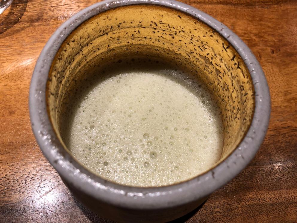 Photogallery






The sign appearing on Soi Langsuan in Bangkok, the little road where you can find restaurant Gaggan and, in front of it, the new-born Gaa, same ownership









The entrance to the restaurant, which recently got the second Michelin star. It’s open only in the evening. There are 65 people here who serve 100 clients daily, divided into two shifts (photo from themalaymailonline.com)









Gaggan’s famous emoji menu: "We first create the dish, then we sum it up with an emoji", he points out (photo from Andershusa/Instagram)









1 
Pink elderflower and watermelon
The tasting menu starts with the notes of the Foo Fighters. The entire first part of the menu is to be eaten with your hands: "This is how it works in India", he explains. First dish: a pearl among elderberry flowers and watermelon in an edible oyster shell. A debut to rinse the palate









2
Yogurt Explosion
Gaggan’s most famous dish. It’s the result of his early internship at elBulli in Roses, Catalonia. "If Ferran Adrià has had Spanish people accept a spherified olives", he says, "why shouldn’t I do the same with an emblem of India?". The spherified yogurt is made with low fat yogurt dipped in a sodium alginate









3
Lick it up. Mushroom peas
With "Lick it up", a hit from the Eighties by Kiss playing in the background, they serve this dish which you must hold with both hands and lick. The sauces, from bottom to top, in "licking order ": tomato, dehydrated mushrooms and mashed green chickpeas. On top, shaved truffle.  "Music, words, food. This is how we represent lightness"









Gaggan holds a cone









4
Tom Yum Kung
This is his version of Tom Yam (or Yum), a popular Thai soup. It’s a cold purée of tom yam served in crispy rice paper with a head of scampi to add flavour. It’s a sort of prawn cocktail in the shape of a cone









5
Goat brain, flower power
A cracker of goat brain ("to us Indians, it’s like foie gras", beams Gaggan) and rice flour. It is served to women first, playing with the similar sounds of flour and flower









6
Eggplant cookie
A cookie of aubergine, a sandwich the size of a coin, held together thanks to some onion chutney. "Out of 20, in Asia ingredients are usually worth 5, technique 15. With this dish I wanted to go in the opposite direction, return to Western minimalism with a universal emblem, that is to say aubergines. It’s a recent dish, which portraits the restaurant as it is now"









7
Chilly bon bon
Chilli pepper spheres. "Chocolates" filled with cumin, chilli pepper, ginger, and other spices. "In India there are four degrees of spiciness: hot, hotter, very hot and hell". The bon bon was mildly hot









8
Idly Sambar
Idly Sambar is a Tamil recipe, from the south of India: vegetable stew, tamarind and varying spices. "The world can be divided into two: those who eat rice, and those who eat bread. In this case, the base is bread made of fermented rice"









9
Banana chicken liver
"My daughter is one year and a half old. She’s difficult when it comes to eating. Give this combination to your children and they’ll be happy"









10
Fish Granola
Granola with fried seabass, walnuts and cheese cream









11
Gin tonic cucumber uni
Sea urchin cones, temaki, key lime and Indian tonic water. "This dish is the result of my trips to Japan: I went there 74 times only in the last couple of years. It has sea urchins from Hokkaido, in the north. In India we never eat raw food". The nori seaweed is made with dill









The selection of sea urchins from Hokkaido. "It’s worth its weight in gold", sighs Gaggan









12
Chutoro sushi
This is Gaggan’s homage to Tuna nigiri, an emblem of his future homeland (in 2021 after closing in Bangkok he’ll open a completely different restaurant in Fukuoka, Japan). Chutoro is a medium-fat tuna. In this case it is caramelised, adding a little emulsion of yuzu on top. The interesting part is below: it’s not rice, but a meringue made of all the ingredients used in sushi, that is to say vinegar, rice, sugar. "Sushi is a one way trip. You’ll never return. Nobody told me how to make it. This dish is a new take on a very personal memory"









13
Foie gras yuzu carrot
Carrot tartelette filled with foie gras. There’s no sweat on the hand: before the tasting they spray yuzu on the palm









Recipe number 14, another excursus between Japan and India









The dish is finished at the table









Whisking the mixture






