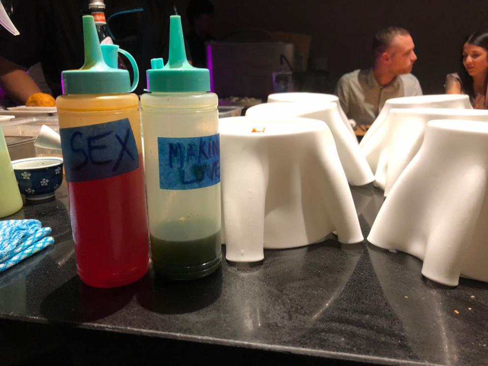 Photogallery






The sign appearing on Soi Langsuan in Bangkok, the little road where you can find restaurant Gaggan and, in front of it, the new-born Gaa, same ownership









The entrance to the restaurant, which recently got the second Michelin star. It’s open only in the evening. There are 65 people here who serve 100 clients daily, divided into two shifts (photo from themalaymailonline.com)









Gaggan’s famous emoji menu: "We first create the dish, then we sum it up with an emoji", he points out (photo from Andershusa/Instagram)









1 
Pink elderflower and watermelon
The tasting menu starts with the notes of the Foo Fighters. The entire first part of the menu is to be eaten with your hands: "This is how it works in India", he explains. First dish: a pearl among elderberry flowers and watermelon in an edible oyster shell. A debut to rinse the palate









2
Yogurt Explosion
Gaggan’s most famous dish. It’s the result of his early internship at elBulli in Roses, Catalonia. "If Ferran Adrià has had Spanish people accept a spherified olives", he says, "why shouldn’t I do the same with an emblem of India?". The spherified yogurt is made with low fat yogurt dipped in a sodium alginate









3
Lick it up. Mushroom peas
With "Lick it up", a hit from the Eighties by Kiss playing in the background, they serve this dish which you must hold with both hands and lick. The sauces, from bottom to top, in "licking order ": tomato, dehydrated mushrooms and mashed green chickpeas. On top, shaved truffle.  "Music, words, food. This is how we represent lightness"









Gaggan holds a cone









4
Tom Yum Kung
This is his version of Tom Yam (or Yum), a popular Thai soup. It’s a cold purée of tom yam served in crispy rice paper with a head of scampi to add flavour. It’s a sort of prawn cocktail in the shape of a cone









5
Goat brain, flower power
A cracker of goat brain ("to us Indians, it’s like foie gras", beams Gaggan) and rice flour. It is served to women first, playing with the similar sounds of flour and flower









6
Eggplant cookie
A cookie of aubergine, a sandwich the size of a coin, held together thanks to some onion chutney. "Out of 20, in Asia ingredients are usually worth 5, technique 15. With this dish I wanted to go in the opposite direction, return to Western minimalism with a universal emblem, that is to say aubergines. It’s a recent dish, which portraits the restaurant as it is now"









7
Chilly bon bon
Chilli pepper spheres. "Chocolates" filled with cumin, chilli pepper, ginger, and other spices. "In India there are four degrees of spiciness: hot, hotter, very hot and hell". The bon bon was mildly hot









8
Idly Sambar
Idly Sambar is a Tamil recipe, from the south of India: vegetable stew, tamarind and varying spices. "The world can be divided into two: those who eat rice, and those who eat bread. In this case, the base is bread made of fermented rice"









9
Banana chicken liver
"My daughter is one year and a half old. She’s difficult when it comes to eating. Give this combination to your children and they’ll be happy"









10
Fish Granola
Granola with fried seabass, walnuts and cheese cream









11
Gin tonic cucumber uni
Sea urchin cones, temaki, key lime and Indian tonic water. "This dish is the result of my trips to Japan: I went there 74 times only in the last couple of years. It has sea urchins from Hokkaido, in the north. In India we never eat raw food". The nori seaweed is made with dill









The selection of sea urchins from Hokkaido. "It’s worth its weight in gold", sighs Gaggan









12
Chutoro sushi
This is Gaggan’s homage to Tuna nigiri, an emblem of his future homeland (in 2021 after closing in Bangkok he’ll open a completely different restaurant in Fukuoka, Japan). Chutoro is a medium-fat tuna. In this case it is caramelised, adding a little emulsion of yuzu on top. The interesting part is below: it’s not rice, but a meringue made of all the ingredients used in sushi, that is to say vinegar, rice, sugar. "Sushi is a one way trip. You’ll never return. Nobody told me how to make it. This dish is a new take on a very personal memory"









13
Foie gras yuzu carrot
Carrot tartelette filled with foie gras. There’s no sweat on the hand: before the tasting they spray yuzu on the palm









Recipe number 14, another excursus between Japan and India









The dish is finished at the table









Whisking the mixture









14
Green vegetable matcha
Green apple gazpacho, cucumber and matcha tea. "I first fell in love with Japan thanks to tea. This looks like Japan but tastes of India and represents Gaggan"









15
Pork Vindaloo 
Vindaloo is a recipe from Goa, the Portuguese feud in west India. It’s pork, seasoned with garlic, vinegar and hot chilli pepper. In this case the fried texture is super-crispy, enriched with Japanese mustard which gives value to the Iberian pig marinated in wine and spices









New dishing out at the Chef's Table









16
Scallop uncooked curry
Scallops with green chilli, fried shallot and coconut ice cream. A “fake-curry ". The dish is served with a complaint about the past: "It’s the British who brought curry. It’s not part of our heritage, just like Chicken tikka masala. For me curry is a universal flavour, suitable for everything"






