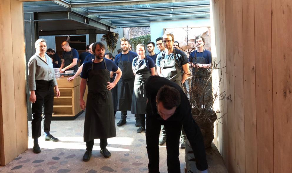 Photogallery






Noma 2.0 is in Christianshavn, the same neighbourhood as the first Noma. They’re 1.5 km apart, a 15 minutes’ walk. This picture shows the distance: to the right, there’s the warehouse of the old location (in Strandgade 93), to the left the smokestacks of Amager Bakke, the futuristic incinerator below which stands the new Noma (in Refshalevej 96)









Weather permitting, you can have a peaceful walk between the previous Noma to today’s Noma 









The new Noma is on an isthmus surrounded by canals. In the future they also want to reclaim some small parts for hydroponic farming









Bucolic scene with incinerator









Bikes left outside Noma. It’s the favourite means of transport among employees and interns









The long path taking you to the restaurant. The fence on the left shows how works are still in progress









On the two sides of the path there are the two new sections of the "Noma village", each with its specialty: grill, hot dishes, snacks, fermentations... In one month’s time, behind the fence we’ll have greenhouses, the test kitchen and the bread making area









To the left, before arriving at the restaurant, the future test kitchen. This will be run by Danish Mette Søberg with Riccardo Canella. "My first challenge?", reveals the latter, for a long time sous chef here, "is to work on the extraction of essential oils" 









The future Test Kitchen









The temporary gangway to the restaurant









Looking from the door to the restaurant, there’s a lake and the smokestacks puffing vapour from the Amager Bakke incinerator. It’s a futuristic project, both in terms of sustainability and architecture. It’s also known as Amager Slope or Copenhill, and its author is starchitect Bjarke Ingels, the same who designed the new Noma. Gradually opened in 2017, it transforms waste into electricity. The goal is to donate electricity to 62500 houses and hot water to 160000. It’s part of an ambitious project to transform Copenhagen into the first city in the world in terms of zero carbon dioxide emissions by 2025. By autumn this year, Amager Slope should open its ski slope, a climbing wall and a hiking track. You’ll be able to slalom on top of the incinerator









The windows from the dining room









Work is still in progress (photo taken on Thursday 22nd February 2018)









Traces of the old building, with barbwire. During WWII, they built bombs here









A view of the dining room at night (photo from Instagram/James Spreadbury)









The entrance to the restaurant






