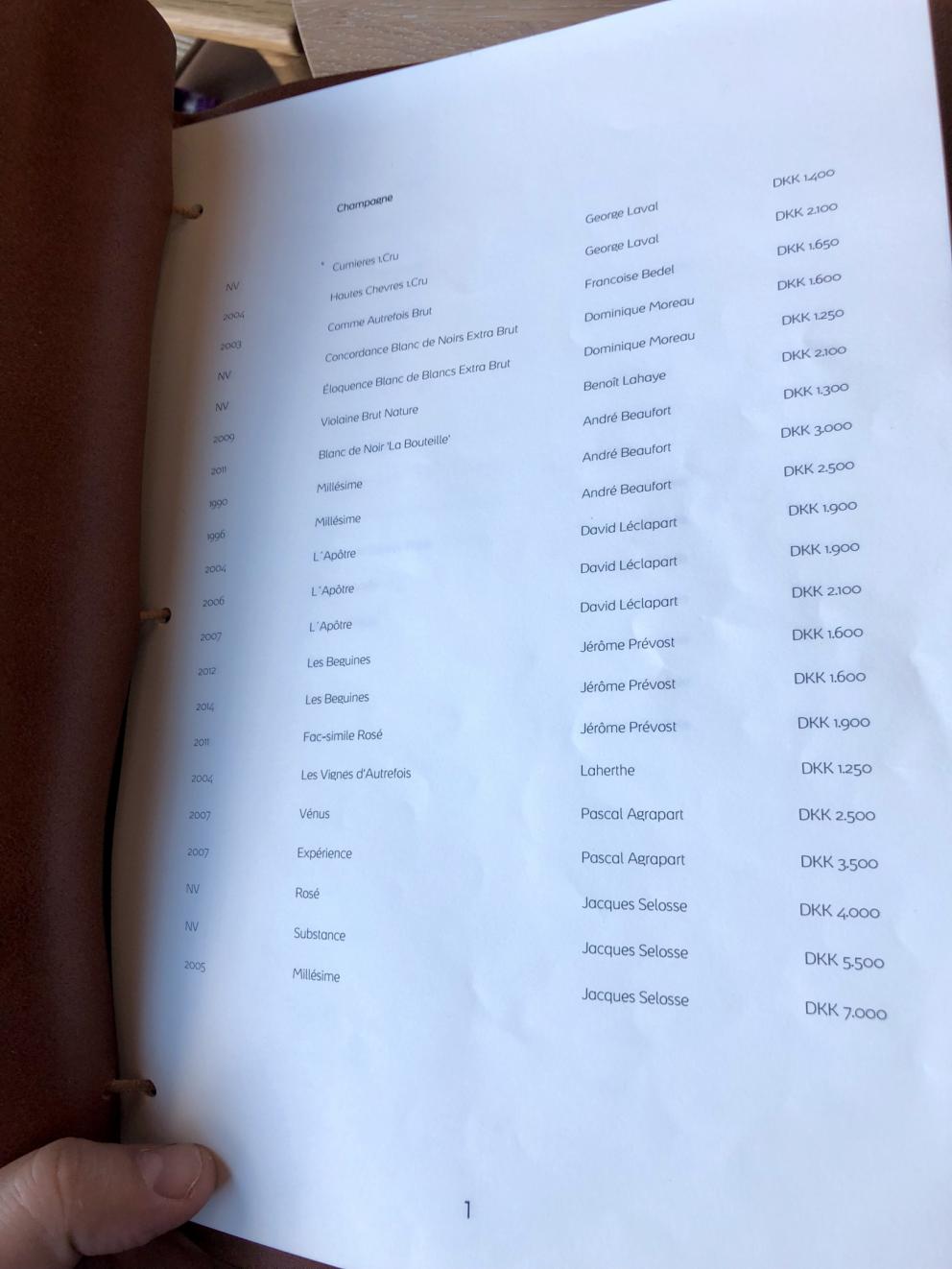 Photogallery






Noma 2.0 is in Christianshavn, the same neighbourhood as the first Noma. They’re 1.5 km apart, a 15 minutes’ walk. This picture shows the distance: to the right, there’s the warehouse of the old location (in Strandgade 93), to the left the smokestacks of Amager Bakke, the futuristic incinerator below which stands the new Noma (in Refshalevej 96)









Weather permitting, you can have a peaceful walk between the previous Noma to today’s Noma 









The new Noma is on an isthmus surrounded by canals. In the future they also want to reclaim some small parts for hydroponic farming









Bucolic scene with incinerator









Bikes left outside Noma. It’s the favourite means of transport among employees and interns









The long path taking you to the restaurant. The fence on the left shows how works are still in progress









On the two sides of the path there are the two new sections of the "Noma village", each with its specialty: grill, hot dishes, snacks, fermentations... In one month’s time, behind the fence we’ll have greenhouses, the test kitchen and the bread making area









To the left, before arriving at the restaurant, the future test kitchen. This will be run by Danish Mette Søberg with Riccardo Canella. "My first challenge?", reveals the latter, for a long time sous chef here, "is to work on the extraction of essential oils" 









The future Test Kitchen









The temporary gangway to the restaurant









Looking from the door to the restaurant, there’s a lake and the smokestacks puffing vapour from the Amager Bakke incinerator. It’s a futuristic project, both in terms of sustainability and architecture. It’s also known as Amager Slope or Copenhill, and its author is starchitect Bjarke Ingels, the same who designed the new Noma. Gradually opened in 2017, it transforms waste into electricity. The goal is to donate electricity to 62500 houses and hot water to 160000. It’s part of an ambitious project to transform Copenhagen into the first city in the world in terms of zero carbon dioxide emissions by 2025. By autumn this year, Amager Slope should open its ski slope, a climbing wall and a hiking track. You’ll be able to slalom on top of the incinerator









The windows from the dining room









Work is still in progress (photo taken on Thursday 22nd February 2018)









Traces of the old building, with barbwire. During WWII, they built bombs here









A view of the dining room at night (photo from Instagram/James Spreadbury)









The entrance to the restaurant









The usual ritual: a welcome from the entire staff, led by Rene Redzepi 









Behind the entrance, there are formaldehyde tanks with creatures from the abyss, shaped as in Damien Hirst’s works. The first image once you’re inside is to reproduce a Scandinavian village









The service kitchen is larger, more spacious and a completely open view from the dining room: "It’s the heart of our Scandinavian village", says Canella. There are 30 cooks working here now. 10 more, compared to the previous Noma









Large skylights above the cooks









There are currently more than 100 people working at Noma, of whom 63 are cooks - 26 employed, and 37 as interns









There’s fire in the kitchen, for the first time









On average, the dining room can host 40 people. "However", complains Redzepi, "there’s always someone who turns up with more people than the ones booked"









While the dining room is set, the outside space still need to be defined









The staff made the dining room decorations. There are no overly expensive designer objects









Dried fish









Seaweeds hanging from the ceiling









Dried octopus heads preserved in salt (with a balloon inside)














Bjarke Ingels and Redzepi’s plan included the wish to recreate a Danish farm









The luminous private dining room









The counter in the dining room. They drew the beams from the canals around the restaurant














The mise en place, bare and strictly without tablecloths









Water jug, candle, flower vase









A warm cloth, to begin with









Australian James Spreadbury, restaurant manager and partner at Noma









Welcome drink: Champagne extra brut Blanc d'Argile from Domaine Vouette et Sorbée









Sea Snail broth. The welcome dish at Noma is, as usual, a hot “soup”









Stefano Ferrano, from Torino, presents the following dish. There’s always a large Italian colony at Noma









Venus clams. Molluscs from Limfjord (Denmark) mixed with decorative clams, typical of Noma. Beside them, shells with blackcurrant oil and “Danish curry”, made with toasted coriander seeds, fennel and fennel seeds









The lid above the following dish. The mussels are not edible









Best of the mussel. Mussels open in a pan with water of fermented barley. «We recreate the mussel», says Canella, «using just the flaps, the best part». The paste is made with scraps from the mussel, cooked in smoked butter









The next dish is conceived and served by Riccardo Canella, the Paduan sous chef who conquered Redzepi, here with dining room intern Feline Hansen









Dried fruits and shrimps. In this case, the heads are not a decoration, but you must suck them –best not eat them because of the bones: they’re filled with a lovely prawn cream. The small crustaceans are still alive when they arrive on a ship straight from the Norwegian fjords









Inside, under the prawn broth skin, there’s fruits and vegetable preserved from the previous summer with raw prawns and gooseberry sauce with blackcurrant oil









How about beverages? There are three options, as usual: wine pairing (6 glasses plus a beer plus sake, 150 euros), juice pairing (juices and extracts, 110 euros) or a choice from the list. They recommend Champagne Chut... Libre from Val'Frison pour Dominique Derain, 50% Pinot Noir, 50% Chardonnay created by a couple who met at the old Noma. Well bodied, it will be a good match throughout the meal






