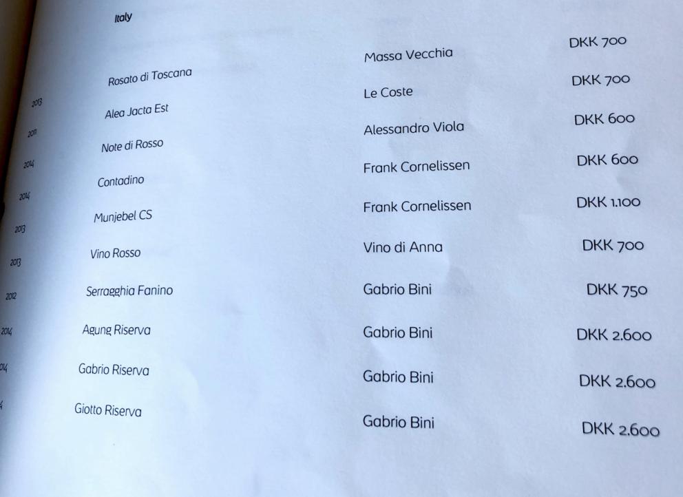 Photogallery






Noma 2.0 is in Christianshavn, the same neighbourhood as the first Noma. They’re 1.5 km apart, a 15 minutes’ walk. This picture shows the distance: to the right, there’s the warehouse of the old location (in Strandgade 93), to the left the smokestacks of Amager Bakke, the futuristic incinerator below which stands the new Noma (in Refshalevej 96)









Weather permitting, you can have a peaceful walk between the previous Noma to today’s Noma 









The new Noma is on an isthmus surrounded by canals. In the future they also want to reclaim some small parts for hydroponic farming









Bucolic scene with incinerator









Bikes left outside Noma. It’s the favourite means of transport among employees and interns









The long path taking you to the restaurant. The fence on the left shows how works are still in progress









On the two sides of the path there are the two new sections of the "Noma village", each with its specialty: grill, hot dishes, snacks, fermentations... In one month’s time, behind the fence we’ll have greenhouses, the test kitchen and the bread making area









To the left, before arriving at the restaurant, the future test kitchen. This will be run by Danish Mette Søberg with Riccardo Canella. "My first challenge?", reveals the latter, for a long time sous chef here, "is to work on the extraction of essential oils" 









The future Test Kitchen









The temporary gangway to the restaurant









Looking from the door to the restaurant, there’s a lake and the smokestacks puffing vapour from the Amager Bakke incinerator. It’s a futuristic project, both in terms of sustainability and architecture. It’s also known as Amager Slope or Copenhill, and its author is starchitect Bjarke Ingels, the same who designed the new Noma. Gradually opened in 2017, it transforms waste into electricity. The goal is to donate electricity to 62500 houses and hot water to 160000. It’s part of an ambitious project to transform Copenhagen into the first city in the world in terms of zero carbon dioxide emissions by 2025. By autumn this year, Amager Slope should open its ski slope, a climbing wall and a hiking track. You’ll be able to slalom on top of the incinerator









The windows from the dining room









Work is still in progress (photo taken on Thursday 22nd February 2018)









Traces of the old building, with barbwire. During WWII, they built bombs here









A view of the dining room at night (photo from Instagram/James Spreadbury)









The entrance to the restaurant









The usual ritual: a welcome from the entire staff, led by Rene Redzepi 









Behind the entrance, there are formaldehyde tanks with creatures from the abyss, shaped as in Damien Hirst’s works. The first image once you’re inside is to reproduce a Scandinavian village









The service kitchen is larger, more spacious and a completely open view from the dining room: "It’s the heart of our Scandinavian village", says Canella. There are 30 cooks working here now. 10 more, compared to the previous Noma









Large skylights above the cooks









There are currently more than 100 people working at Noma, of whom 63 are cooks - 26 employed, and 37 as interns









There’s fire in the kitchen, for the first time









On average, the dining room can host 40 people. "However", complains Redzepi, "there’s always someone who turns up with more people than the ones booked"









While the dining room is set, the outside space still need to be defined









The staff made the dining room decorations. There are no overly expensive designer objects









Dried fish









Seaweeds hanging from the ceiling









Dried octopus heads preserved in salt (with a balloon inside)














Bjarke Ingels and Redzepi’s plan included the wish to recreate a Danish farm









The luminous private dining room









The counter in the dining room. They drew the beams from the canals around the restaurant














The mise en place, bare and strictly without tablecloths









Water jug, candle, flower vase









A warm cloth, to begin with









Australian James Spreadbury, restaurant manager and partner at Noma









Welcome drink: Champagne extra brut Blanc d'Argile from Domaine Vouette et Sorbée









Sea Snail broth. The welcome dish at Noma is, as usual, a hot “soup”









Stefano Ferrano, from Torino, presents the following dish. There’s always a large Italian colony at Noma









Venus clams. Molluscs from Limfjord (Denmark) mixed with decorative clams, typical of Noma. Beside them, shells with blackcurrant oil and “Danish curry”, made with toasted coriander seeds, fennel and fennel seeds









The lid above the following dish. The mussels are not edible









Best of the mussel. Mussels open in a pan with water of fermented barley. «We recreate the mussel», says Canella, «using just the flaps, the best part». The paste is made with scraps from the mussel, cooked in smoked butter









The next dish is conceived and served by Riccardo Canella, the Paduan sous chef who conquered Redzepi, here with dining room intern Feline Hansen









Dried fruits and shrimps. In this case, the heads are not a decoration, but you must suck them –best not eat them because of the bones: they’re filled with a lovely prawn cream. The small crustaceans are still alive when they arrive on a ship straight from the Norwegian fjords









Inside, under the prawn broth skin, there’s fruits and vegetable preserved from the previous summer with raw prawns and gooseberry sauce with blackcurrant oil









How about beverages? There are three options, as usual: wine pairing (6 glasses plus a beer plus sake, 150 euros), juice pairing (juices and extracts, 110 euros) or a choice from the list. They recommend Champagne Chut... Libre from Val'Frison pour Dominique Derain, 50% Pinot Noir, 50% Chardonnay created by a couple who met at the old Noma. Well bodied, it will be a good match throughout the meal









As usual, the wine list starts with Champagne: the cheapest is 1400 crowns (190 euros)









White wines begin with labels from cold climates: first Austria, increasingly popular for its natural wines, then Germany, then all the others









How about Italy? Few names, among the white wines, from North and South






