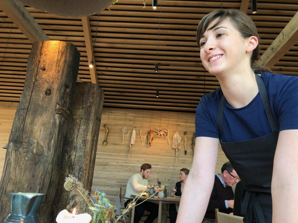 Photogallery






Noma 2.0 is in Christianshavn, the same neighbourhood as the first Noma. They’re 1.5 km apart, a 15 minutes’ walk. This picture shows the distance: to the right, there’s the warehouse of the old location (in Strandgade 93), to the left the smokestacks of Amager Bakke, the futuristic incinerator below which stands the new Noma (in Refshalevej 96)









Weather permitting, you can have a peaceful walk between the previous Noma to today’s Noma 









The new Noma is on an isthmus surrounded by canals. In the future they also want to reclaim some small parts for hydroponic farming









Bucolic scene with incinerator









Bikes left outside Noma. It’s the favourite means of transport among employees and interns









The long path taking you to the restaurant. The fence on the left shows how works are still in progress









On the two sides of the path there are the two new sections of the "Noma village", each with its specialty: grill, hot dishes, snacks, fermentations... In one month’s time, behind the fence we’ll have greenhouses, the test kitchen and the bread making area









To the left, before arriving at the restaurant, the future test kitchen. This will be run by Danish Mette Søberg with Riccardo Canella. "My first challenge?", reveals the latter, for a long time sous chef here, "is to work on the extraction of essential oils" 









The future Test Kitchen









The temporary gangway to the restaurant









Looking from the door to the restaurant, there’s a lake and the smokestacks puffing vapour from the Amager Bakke incinerator. It’s a futuristic project, both in terms of sustainability and architecture. It’s also known as Amager Slope or Copenhill, and its author is starchitect Bjarke Ingels, the same who designed the new Noma. Gradually opened in 2017, it transforms waste into electricity. The goal is to donate electricity to 62500 houses and hot water to 160000. It’s part of an ambitious project to transform Copenhagen into the first city in the world in terms of zero carbon dioxide emissions by 2025. By autumn this year, Amager Slope should open its ski slope, a climbing wall and a hiking track. You’ll be able to slalom on top of the incinerator









The windows from the dining room









Work is still in progress (photo taken on Thursday 22nd February 2018)









Traces of the old building, with barbwire. During WWII, they built bombs here









A view of the dining room at night (photo from Instagram/James Spreadbury)









The entrance to the restaurant









The usual ritual: a welcome from the entire staff, led by Rene Redzepi 









Behind the entrance, there are formaldehyde tanks with creatures from the abyss, shaped as in Damien Hirst’s works. The first image once you’re inside is to reproduce a Scandinavian village









The service kitchen is larger, more spacious and a completely open view from the dining room: "It’s the heart of our Scandinavian village", says Canella. There are 30 cooks working here now. 10 more, compared to the previous Noma









Large skylights above the cooks









There are currently more than 100 people working at Noma, of whom 63 are cooks - 26 employed, and 37 as interns









There’s fire in the kitchen, for the first time









On average, the dining room can host 40 people. "However", complains Redzepi, "there’s always someone who turns up with more people than the ones booked"









While the dining room is set, the outside space still need to be defined









The staff made the dining room decorations. There are no overly expensive designer objects









Dried fish









Seaweeds hanging from the ceiling









Dried octopus heads preserved in salt (with a balloon inside)














Bjarke Ingels and Redzepi’s plan included the wish to recreate a Danish farm









The luminous private dining room









The counter in the dining room. They drew the beams from the canals around the restaurant














The mise en place, bare and strictly without tablecloths









Water jug, candle, flower vase









A warm cloth, to begin with









Australian James Spreadbury, restaurant manager and partner at Noma









Welcome drink: Champagne extra brut Blanc d'Argile from Domaine Vouette et Sorbée









Sea Snail broth. The welcome dish at Noma is, as usual, a hot “soup”









Stefano Ferrano, from Torino, presents the following dish. There’s always a large Italian colony at Noma









Venus clams. Molluscs from Limfjord (Denmark) mixed with decorative clams, typical of Noma. Beside them, shells with blackcurrant oil and “Danish curry”, made with toasted coriander seeds, fennel and fennel seeds









The lid above the following dish. The mussels are not edible









Best of the mussel. Mussels open in a pan with water of fermented barley. «We recreate the mussel», says Canella, «using just the flaps, the best part». The paste is made with scraps from the mussel, cooked in smoked butter









The next dish is conceived and served by Riccardo Canella, the Paduan sous chef who conquered Redzepi, here with dining room intern Feline Hansen









Dried fruits and shrimps. In this case, the heads are not a decoration, but you must suck them –best not eat them because of the bones: they’re filled with a lovely prawn cream. The small crustaceans are still alive when they arrive on a ship straight from the Norwegian fjords









Inside, under the prawn broth skin, there’s fruits and vegetable preserved from the previous summer with raw prawns and gooseberry sauce with blackcurrant oil









How about beverages? There are three options, as usual: wine pairing (6 glasses plus a beer plus sake, 150 euros), juice pairing (juices and extracts, 110 euros) or a choice from the list. They recommend Champagne Chut... Libre from Val'Frison pour Dominique Derain, 50% Pinot Noir, 50% Chardonnay created by a couple who met at the old Noma. Well bodied, it will be a good match throughout the meal









As usual, the wine list starts with Champagne: the cheapest is 1400 crowns (190 euros)









White wines begin with labels from cold climates: first Austria, increasingly popular for its natural wines, then Germany, then all the others









How about Italy? Few names, among the white wines, from North and South









A dozen red/orange wines









Sea star, that is to say Cured trout roe and eggs, the emblem dish of this new era. They recommend moving the teaspoon from the heart to the edges of the tentacles. Aesthetics win over taste









Jellyfish. The jellyfish gel in the middle is in fact a clarified broth of calamari and recalls the texture of jellyfish. "We tried to cook jellyfish in 300 different ways but none was convincing so far". All around, pickled seaweed. The gel is almost tasteless, it serves to clean the palate after the pickles









Rene Redzepi himself presents the content of the first Seafood platter.









French style service with a small plate below for the empty shells









It’s made of two (per two) pieces: queen clam and mahogany clam









The Queen Clam is a very small variety of Norwegian scallop, seasoned with a vegetal reduction made with cucumber and peas miso. The red tip is the coral. "You should eat it using the top shell ", recommends Redzepi









The Mahogany clam is a centennial clam from the North Sea, very popular in Denmark and Iceland. «You can tell the age by the number of rings, like with trees», says Redzepi, «In 2007 they found one that was 450 years old. We’ve had it in the menu for a decade or so». The razor clam shell serves as teaspoon









Inside, there’s obviously not just a bare Mahogany. «We open it when the client arrives», says Canella, «remove the entrails and then slice it so as to preserve its firm texture». It’s seasoned with stir-fried gooseberry, capers of blackcurrants and blackcurrant sprouts preserved in vinegar. The sauce is made with mussel water









A note on the chairs: they’re more minimalistic. They’re no longer covered in sheepskin or leather from other Danish animals, in the style of Noma 1.0. The most significant element is the napkin: if you go to the toilet, they no longer replace it with a new one. There’s the old one, tied to the chair. "This is sustainability", they explain









The second seafood platter. It’s made of Sea cucumber and sour cream in various textures, including «chicharrones» (at 9 o’clock), sea urchins (at 12 and 3) and gigas oyster (at 6)









Sea urchins pressed in fresh cream and pumpkin seeds









Giga Oyster, a huge oyster from the Pacific, quickly steamed and garnished with pickles. Noma only reserved one thousand of these. In the menu until available









The following dish, off the menu, is again from Canella: horse mussel ragout, rare specimen of which 30 arrive at 'Noma each week









They cook the mussel as if it were kidney, in a sort of Bolognese sauce but with ginger. Ginger? "Yes, we’ve decided to include it, as with other spices, after our Mexican experience"









Another Italian presents a dish, Edoardo Fiaschi from Prato, at Noma for 3 years now









Squid in seaweed butter. An almost neglected Danish squid lightly seared in fermented koji oil, rolled and seasoned with seaweed butter and served on sticks of blackcurrant that widen its aromas. Formidable and beautiful









The following dish is inside a nice bee wax container. It’s made with balloons covered multiple times in bee wax. «We spent weeks making them. We’ve made thousands». They’re disposable...









Sea snail and roses. They recommend to: "Eat it keeping the bee wax on your hands "









Sea snail. Another small nibble from the top part of the sea snail, lightly warmed up in water and served on a reduction of lemon thyme









A sea snail toothpick, initially carved by Redzepi himself









Head of the cod, (right), the real main course at Noma









Another rather laborious recipe. «It takes half an hour just to separate the head. We remove the skin, the collagen, we cut mandibles, tongue, cheek and the part behind. We rinse it in water, spices, koji and cook it in the yakitori with a glaze of mushrooms and spiced fennel broth»









You can garnish the cod as you choose, with a paste of ants (top right corner), a slightly spicy emulsion of koji oil, water and horseradish sauce (left) and Danish curry (bottom)









On the side of the cod, there’s also wild garlic seasoned with smoked butter and roasted yeast. Intense flavour









Cod bones after the tasting









An interlocutory snack made of cod cheek









Pickled vegetables and arctic herbs. The only vegetable dish in the menu, marks the passage from savoury to sweet dishes. Between June and August 2018 the menu at Noma will be 100% vegetarian









Preparation time: half an hour! A challenge for the person making it









Mussels appear once again, a classic emblem









This time it’s a dessert in the shape of a small sandwich. Pear and roasted kelp ice cream 









Cloudberries and pinecones. A dessert that continues Redzepi’s saga of unsweet sweets: cloudberries, pinecones preserved in sugar, yogurt snow (by Italian Jessica Natali) and a sea snail made with cloudberry sorbet









Filtered coffee made with stolen kenyoti seeds farmed in Honduras by a Norwegian guy. Italian sommelier Francesca Niro tells us this story. «In Denmark», she says, «coffee is not a final act»









Sugar kelp tart. Tartelletta di alga kelp con pralinato di pino (sul modello di quello di mandorle, autore Canella), panna e crisp di ostrica






