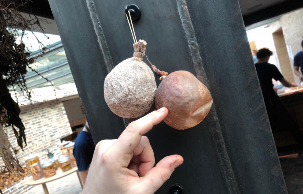 Photogallery






Noma 2.0 is in Christianshavn, the same neighbourhood as the first Noma. They’re 1.5 km apart, a 15 minutes’ walk. This picture shows the distance: to the right, there’s the warehouse of the old location (in Strandgade 93), to the left the smokestacks of Amager Bakke, the futuristic incinerator below which stands the new Noma (in Refshalevej 96)









Weather permitting, you can have a peaceful walk between the previous Noma to today’s Noma 









The new Noma is on an isthmus surrounded by canals. In the future they also want to reclaim some small parts for hydroponic farming









Bucolic scene with incinerator









Bikes left outside Noma. It’s the favourite means of transport among employees and interns









The long path taking you to the restaurant. The fence on the left shows how works are still in progress









On the two sides of the path there are the two new sections of the "Noma village", each with its specialty: grill, hot dishes, snacks, fermentations... In one month’s time, behind the fence we’ll have greenhouses, the test kitchen and the bread making area









To the left, before arriving at the restaurant, the future test kitchen. This will be run by Danish Mette Søberg with Riccardo Canella. "My first challenge?", reveals the latter, for a long time sous chef here, "is to work on the extraction of essential oils" 









The future Test Kitchen









The temporary gangway to the restaurant









Looking from the door to the restaurant, there’s a lake and the smokestacks puffing vapour from the Amager Bakke incinerator. It’s a futuristic project, both in terms of sustainability and architecture. It’s also known as Amager Slope or Copenhill, and its author is starchitect Bjarke Ingels, the same who designed the new Noma. Gradually opened in 2017, it transforms waste into electricity. The goal is to donate electricity to 62500 houses and hot water to 160000. It’s part of an ambitious project to transform Copenhagen into the first city in the world in terms of zero carbon dioxide emissions by 2025. By autumn this year, Amager Slope should open its ski slope, a climbing wall and a hiking track. You’ll be able to slalom on top of the incinerator









The windows from the dining room









Work is still in progress (photo taken on Thursday 22nd February 2018)









Traces of the old building, with barbwire. During WWII, they built bombs here









A view of the dining room at night (photo from Instagram/James Spreadbury)









The entrance to the restaurant









The usual ritual: a welcome from the entire staff, led by Rene Redzepi 









Behind the entrance, there are formaldehyde tanks with creatures from the abyss, shaped as in Damien Hirst’s works. The first image once you’re inside is to reproduce a Scandinavian village









The service kitchen is larger, more spacious and a completely open view from the dining room: "It’s the heart of our Scandinavian village", says Canella. There are 30 cooks working here now. 10 more, compared to the previous Noma









Large skylights above the cooks









There are currently more than 100 people working at Noma, of whom 63 are cooks - 26 employed, and 37 as interns









There’s fire in the kitchen, for the first time









On average, the dining room can host 40 people. "However", complains Redzepi, "there’s always someone who turns up with more people than the ones booked"









While the dining room is set, the outside space still need to be defined









The staff made the dining room decorations. There are no overly expensive designer objects









Dried fish









Seaweeds hanging from the ceiling






