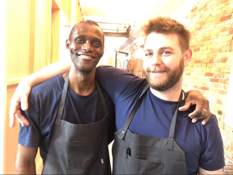 Photogallery






Noma 2.0 is in Christianshavn, the same neighbourhood as the first Noma. They’re 1.5 km apart, a 15 minutes’ walk. This picture shows the distance: to the right, there’s the warehouse of the old location (in Strandgade 93), to the left the smokestacks of Amager Bakke, the futuristic incinerator below which stands the new Noma (in Refshalevej 96)









Weather permitting, you can have a peaceful walk between the previous Noma to today’s Noma 









The new Noma is on an isthmus surrounded by canals. In the future they also want to reclaim some small parts for hydroponic farming









Bucolic scene with incinerator









Bikes left outside Noma. It’s the favourite means of transport among employees and interns









The long path taking you to the restaurant. The fence on the left shows how works are still in progress









On the two sides of the path there are the two new sections of the "Noma village", each with its specialty: grill, hot dishes, snacks, fermentations... In one month’s time, behind the fence we’ll have greenhouses, the test kitchen and the bread making area









To the left, before arriving at the restaurant, the future test kitchen. This will be run by Danish Mette Søberg with Riccardo Canella. "My first challenge?", reveals the latter, for a long time sous chef here, "is to work on the extraction of essential oils" 









The future Test Kitchen









The temporary gangway to the restaurant









Looking from the door to the restaurant, there’s a lake and the smokestacks puffing vapour from the Amager Bakke incinerator. It’s a futuristic project, both in terms of sustainability and architecture. It’s also known as Amager Slope or Copenhill, and its author is starchitect Bjarke Ingels, the same who designed the new Noma. Gradually opened in 2017, it transforms waste into electricity. The goal is to donate electricity to 62500 houses and hot water to 160000. It’s part of an ambitious project to transform Copenhagen into the first city in the world in terms of zero carbon dioxide emissions by 2025. By autumn this year, Amager Slope should open its ski slope, a climbing wall and a hiking track. You’ll be able to slalom on top of the incinerator









The windows from the dining room









Work is still in progress (photo taken on Thursday 22nd February 2018)









Traces of the old building, with barbwire. During WWII, they built bombs here









A view of the dining room at night (photo from Instagram/James Spreadbury)









The entrance to the restaurant









The usual ritual: a welcome from the entire staff, led by Rene Redzepi 









Behind the entrance, there are formaldehyde tanks with creatures from the abyss, shaped as in Damien Hirst’s works. The first image once you’re inside is to reproduce a Scandinavian village









The service kitchen is larger, more spacious and a completely open view from the dining room: "It’s the heart of our Scandinavian village", says Canella. There are 30 cooks working here now. 10 more, compared to the previous Noma









Large skylights above the cooks









There are currently more than 100 people working at Noma, of whom 63 are cooks - 26 employed, and 37 as interns









There’s fire in the kitchen, for the first time









On average, the dining room can host 40 people. "However", complains Redzepi, "there’s always someone who turns up with more people than the ones booked"









While the dining room is set, the outside space still need to be defined









The staff made the dining room decorations. There are no overly expensive designer objects









Dried fish









Seaweeds hanging from the ceiling









Dried octopus heads preserved in salt (with a balloon inside)














Bjarke Ingels and Redzepi’s plan included the wish to recreate a Danish farm









The luminous private dining room









The counter in the dining room. They drew the beams from the canals around the restaurant














The mise en place, bare and strictly without tablecloths









Water jug, candle, flower vase









A warm cloth, to begin with









Australian James Spreadbury, restaurant manager and partner at Noma









Welcome drink: Champagne extra brut Blanc d'Argile from Domaine Vouette et Sorbée









Sea Snail broth. The welcome dish at Noma is, as usual, a hot “soup”









Stefano Ferrano, from Torino, presents the following dish. There’s always a large Italian colony at Noma









Venus clams. Molluscs from Limfjord (Denmark) mixed with decorative clams, typical of Noma. Beside them, shells with blackcurrant oil and “Danish curry”, made with toasted coriander seeds, fennel and fennel seeds









The lid above the following dish. The mussels are not edible









Best of the mussel. Mussels open in a pan with water of fermented barley. «We recreate the mussel», says Canella, «using just the flaps, the best part». The paste is made with scraps from the mussel, cooked in smoked butter









The next dish is conceived and served by Riccardo Canella, the Paduan sous chef who conquered Redzepi, here with dining room intern Feline Hansen









Dried fruits and shrimps. In this case, the heads are not a decoration, but you must suck them –best not eat them because of the bones: they’re filled with a lovely prawn cream. The small crustaceans are still alive when they arrive on a ship straight from the Norwegian fjords









Inside, under the prawn broth skin, there’s fruits and vegetable preserved from the previous summer with raw prawns and gooseberry sauce with blackcurrant oil









How about beverages? There are three options, as usual: wine pairing (6 glasses plus a beer plus sake, 150 euros), juice pairing (juices and extracts, 110 euros) or a choice from the list. They recommend Champagne Chut... Libre from Val'Frison pour Dominique Derain, 50% Pinot Noir, 50% Chardonnay created by a couple who met at the old Noma. Well bodied, it will be a good match throughout the meal









As usual, the wine list starts with Champagne: the cheapest is 1400 crowns (190 euros)









White wines begin with labels from cold climates: first Austria, increasingly popular for its natural wines, then Germany, then all the others









How about Italy? Few names, among the white wines, from North and South









A dozen red/orange wines









Sea star, that is to say Cured trout roe and eggs, the emblem dish of this new era. They recommend moving the teaspoon from the heart to the edges of the tentacles. Aesthetics win over taste









Jellyfish. The jellyfish gel in the middle is in fact a clarified broth of calamari and recalls the texture of jellyfish. "We tried to cook jellyfish in 300 different ways but none was convincing so far". All around, pickled seaweed. The gel is almost tasteless, it serves to clean the palate after the pickles









Rene Redzepi himself presents the content of the first Seafood platter.









French style service with a small plate below for the empty shells









It’s made of two (per two) pieces: queen clam and mahogany clam









The Queen Clam is a very small variety of Norwegian scallop, seasoned with a vegetal reduction made with cucumber and peas miso. The red tip is the coral. "You should eat it using the top shell ", recommends Redzepi









The Mahogany clam is a centennial clam from the North Sea, very popular in Denmark and Iceland. «You can tell the age by the number of rings, like with trees», says Redzepi, «In 2007 they found one that was 450 years old. We’ve had it in the menu for a decade or so». The razor clam shell serves as teaspoon









Inside, there’s obviously not just a bare Mahogany. «We open it when the client arrives», says Canella, «remove the entrails and then slice it so as to preserve its firm texture». It’s seasoned with stir-fried gooseberry, capers of blackcurrants and blackcurrant sprouts preserved in vinegar. The sauce is made with mussel water









A note on the chairs: they’re more minimalistic. They’re no longer covered in sheepskin or leather from other Danish animals, in the style of Noma 1.0. The most significant element is the napkin: if you go to the toilet, they no longer replace it with a new one. There’s the old one, tied to the chair. "This is sustainability", they explain









The second seafood platter. It’s made of Sea cucumber and sour cream in various textures, including «chicharrones» (at 9 o’clock), sea urchins (at 12 and 3) and gigas oyster (at 6)









Sea urchins pressed in fresh cream and pumpkin seeds









Giga Oyster, a huge oyster from the Pacific, quickly steamed and garnished with pickles. Noma only reserved one thousand of these. In the menu until available









The following dish, off the menu, is again from Canella: horse mussel ragout, rare specimen of which 30 arrive at 'Noma each week









They cook the mussel as if it were kidney, in a sort of Bolognese sauce but with ginger. Ginger? "Yes, we’ve decided to include it, as with other spices, after our Mexican experience"









Another Italian presents a dish, Edoardo Fiaschi from Prato, at Noma for 3 years now









Squid in seaweed butter. An almost neglected Danish squid lightly seared in fermented koji oil, rolled and seasoned with seaweed butter and served on sticks of blackcurrant that widen its aromas. Formidable and beautiful









The following dish is inside a nice bee wax container. It’s made with balloons covered multiple times in bee wax. «We spent weeks making them. We’ve made thousands». They’re disposable...









Sea snail and roses. They recommend to: "Eat it keeping the bee wax on your hands "









Sea snail. Another small nibble from the top part of the sea snail, lightly warmed up in water and served on a reduction of lemon thyme









A sea snail toothpick, initially carved by Redzepi himself









Head of the cod, (right), the real main course at Noma









Another rather laborious recipe. «It takes half an hour just to separate the head. We remove the skin, the collagen, we cut mandibles, tongue, cheek and the part behind. We rinse it in water, spices, koji and cook it in the yakitori with a glaze of mushrooms and spiced fennel broth»









You can garnish the cod as you choose, with a paste of ants (top right corner), a slightly spicy emulsion of koji oil, water and horseradish sauce (left) and Danish curry (bottom)









On the side of the cod, there’s also wild garlic seasoned with smoked butter and roasted yeast. Intense flavour









Cod bones after the tasting









An interlocutory snack made of cod cheek









Pickled vegetables and arctic herbs. The only vegetable dish in the menu, marks the passage from savoury to sweet dishes. Between June and August 2018 the menu at Noma will be 100% vegetarian









Preparation time: half an hour! A challenge for the person making it









Mussels appear once again, a classic emblem









This time it’s a dessert in the shape of a small sandwich. Pear and roasted kelp ice cream 









Cloudberries and pinecones. A dessert that continues Redzepi’s saga of unsweet sweets: cloudberries, pinecones preserved in sugar, yogurt snow (by Italian Jessica Natali) and a sea snail made with cloudberry sorbet









Filtered coffee made with stolen kenyoti seeds farmed in Honduras by a Norwegian guy. Italian sommelier Francesca Niro tells us this story. «In Denmark», she says, «coffee is not a final act»









Sugar kelp tart. Tartelletta di alga kelp con pralinato di pino (sul modello di quello di mandorle, autore Canella), panna e crisp di ostrica









Sugar kelp tart. Jessica Natali, 23, from the March, has been at Noma for 4 years now









Natali introduces the last dish, Plankton cake









It’s Redzepi’s tribute to Andalusian chef Angel Leon, the chef who brought the abyss of the sea on fine dining tables. A final trivia fact at the end of the meal: we were never served bread, a historic strongpoint at Noma. "There’s no need for bread in this menu", said Redzepi









With Canella we walk the very long corridor that starts from the opposite side of the room, right after the entrance









It’s the rationalised and enlarged equivalent of the previous Noma’s first floor. Dozens of guys are making the pre-preparations






