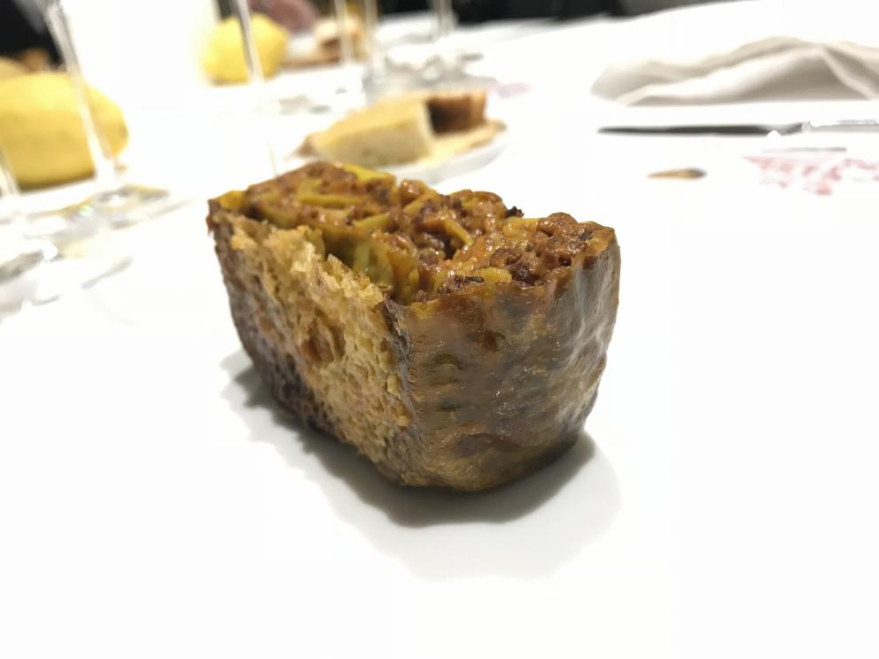 Photogallery






Water, oil, lemon and liquorice: purity. «I use it to clean the palate before the tasting. Water is energy, liquorice is synergic strength, lemon is my emblem, oil [chilled at -40°C] is my homeland»









Italy is also about bread. Taglienti makes it himself, with a 200-year-old mother yeast. On the small plate, at least two delicious types: whole wheat bread, to the right, and schiacciata with herbs and courgette flowers and dehydrated citrus fruits









A dish that, within this new tasting menu, represents something different, that is to say a hint to what the chef has done so far: Bianco e nero di seppia was born in 2009: «The input was a dish of spaghetti with squid ink I had on the beach in Sicily». Under the squid, pressed as if it were pasta, eight types of citrus fruits and panna cotta with sea urchins. Extracts, fonds and jus are increasingly essential in the cuisine of Taglienti. Through them, he channels the essence of flavour: «We always have 12 sauces in the kitchen: fonds of every possible meat, 6 juices from every citrus fruit, plus extracts». The photo shows a previous dinner we had. The author is Tanio Liotta









«I asked myself, why not serve saltimbocca alla romana?». Here it is: raw Piedmontese meat, culatello, butter emulsified with a little flour, thus adding a classic saltimbocca element, then an extract of sage and white wine – the sage is previously micro-fermented close to the stove. «In France cuisine is only about fine dining. In Italy, cuisine comprises everything». Taglienti uses the word vision for this dish









Fat goose liver from Mortara wrapped in steamed cabbage, warm oyster cream and casseoula sauce: the expression of a territory. «This is my idea of casseoula, which we cook in a classic way, and then extract so as to make a sauce». The cabbage recalls caponet or lattuga ripiena alla ligure (served with tocco, a thick meat broth which we’ll mention later too), but has fat liver too. A fantastic dish






