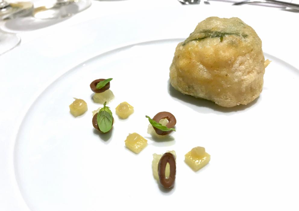 Photogallery






Water, oil, lemon and liquorice: purity. «I use it to clean the palate before the tasting. Water is energy, liquorice is synergic strength, lemon is my emblem, oil [chilled at -40°C] is my homeland»









Italy is also about bread. Taglienti makes it himself, with a 200-year-old mother yeast. On the small plate, at least two delicious types: whole wheat bread, to the right, and schiacciata with herbs and courgette flowers and dehydrated citrus fruits









A dish that, within this new tasting menu, represents something different, that is to say a hint to what the chef has done so far: Bianco e nero di seppia was born in 2009: «The input was a dish of spaghetti with squid ink I had on the beach in Sicily». Under the squid, pressed as if it were pasta, eight types of citrus fruits and panna cotta with sea urchins. Extracts, fonds and jus are increasingly essential in the cuisine of Taglienti. Through them, he channels the essence of flavour: «We always have 12 sauces in the kitchen: fonds of every possible meat, 6 juices from every citrus fruit, plus extracts». The photo shows a previous dinner we had. The author is Tanio Liotta









«I asked myself, why not serve saltimbocca alla romana?». Here it is: raw Piedmontese meat, culatello, butter emulsified with a little flour, thus adding a classic saltimbocca element, then an extract of sage and white wine – the sage is previously micro-fermented close to the stove. «In France cuisine is only about fine dining. In Italy, cuisine comprises everything». Taglienti uses the word vision for this dish









Fat goose liver from Mortara wrapped in steamed cabbage, warm oyster cream and casseoula sauce: the expression of a territory. «This is my idea of casseoula, which we cook in a classic way, and then extract so as to make a sauce». The cabbage recalls caponet or lattuga ripiena alla ligure (served with tocco, a thick meat broth which we’ll mention later too), but has fat liver too. A fantastic dish









Traditional Lasagne Bolognese: (new) avant-garde. A very thin dough, with the ragù simmering for six hours






