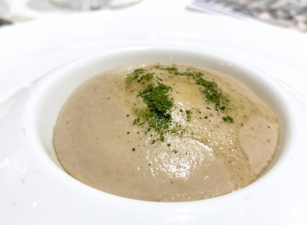 Photogallery






Water, oil, lemon and liquorice: purity. «I use it to clean the palate before the tasting. Water is energy, liquorice is synergic strength, lemon is my emblem, oil [chilled at -40°C] is my homeland»









Italy is also about bread. Taglienti makes it himself, with a 200-year-old mother yeast. On the small plate, at least two delicious types: whole wheat bread, to the right, and schiacciata with herbs and courgette flowers and dehydrated citrus fruits









A dish that, within this new tasting menu, represents something different, that is to say a hint to what the chef has done so far: Bianco e nero di seppia was born in 2009: «The input was a dish of spaghetti with squid ink I had on the beach in Sicily». Under the squid, pressed as if it were pasta, eight types of citrus fruits and panna cotta with sea urchins. Extracts, fonds and jus are increasingly essential in the cuisine of Taglienti. Through them, he channels the essence of flavour: «We always have 12 sauces in the kitchen: fonds of every possible meat, 6 juices from every citrus fruit, plus extracts». The photo shows a previous dinner we had. The author is Tanio Liotta









«I asked myself, why not serve saltimbocca alla romana?». Here it is: raw Piedmontese meat, culatello, butter emulsified with a little flour, thus adding a classic saltimbocca element, then an extract of sage and white wine – the sage is previously micro-fermented close to the stove. «In France cuisine is only about fine dining. In Italy, cuisine comprises everything». Taglienti uses the word vision for this dish









Fat goose liver from Mortara wrapped in steamed cabbage, warm oyster cream and casseoula sauce: the expression of a territory. «This is my idea of casseoula, which we cook in a classic way, and then extract so as to make a sauce». The cabbage recalls caponet or lattuga ripiena alla ligure (served with tocco, a thick meat broth which we’ll mention later too), but has fat liver too. A fantastic dish









Traditional Lasagne Bolognese: (new) avant-garde. A very thin dough, with the ragù simmering for six hours









Frittura di pesce morone al salmoriglio: heritage. «Here’s salmoriglio [not in the photo] an ancient Sicilian and Calabrian seasoning that is more and more forgotten and was one used for chargrilled fish» (olive oil, garlic, oregano, lemon juice, basil, fresh hot green chilli pepper). The batter is made with beer and encloses the fried fish as well as a sauce that is halfway between Provencal anchoiade, with anchovies, and Ligurian tapenade, with olives. Then, also fried in batter, a leaf of basil from the south, «because it’s large, while the basil from Prà in Liguria has small leaves» and then bergamot, Moroccan preserved lemon, olives form Arma di Taggia. Very good









Quintessenza di un tocco genovese: culinary memories. We’ve already mentioned tocco: it’s a sauce based on the very slow cooking of vegetables, tomatoes, mushrooms, bone marrow and then the meat you add so it releases its juices and flavours, and is served separately as a main course. Tocco is a concentrate of aromas that stays in the background. It’s a seasoning, usually, but Taglienti serves it by itself. An elegant blast of flavour









Artichoke cake: evolution. Taglienti adds an idea of tarte tatin to a classic. And a touch of Cynar. A dish halfway between savoury and sweet






