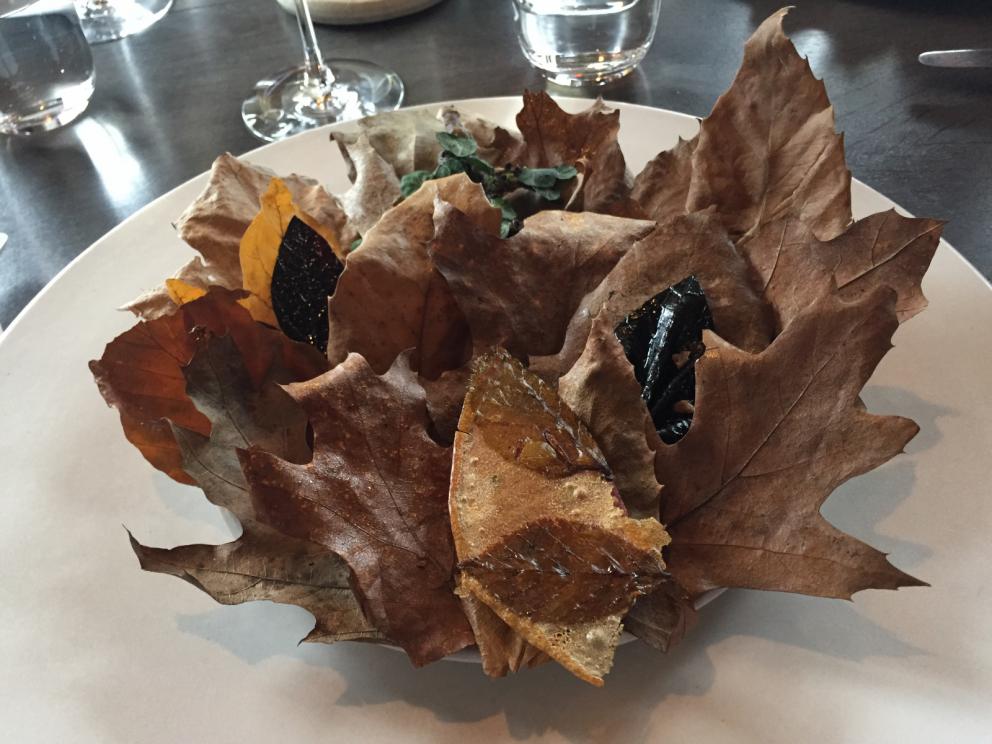 Photogallery






The traditional welcome at Noma: the chefs from the service kitchen greet the guests. In the middle, Italian Riccardo Canella, who will help us describing the last menu in detail (photo gallery by Luca Iaccarino and Gabriele Zanatta)









Warm broth of cloudberries. It’s the last welcome dish at Noma. It’s cold outside but as soon as you sit inside, you get warm thanks to this hot broth made with cloudberries enriched with rhubarb root oil. You dip a bouquet of hay, lemon thyme and mountain pine. Corroborating









Riccardo Canella brings a preview of what will follow









It’s a dish with seafood, including a huge (and alive) king crab, sea urchins and oysters









Apple of the season









Apple of the season. Once you open the shell, many small apple parisienne appear in a juice made with centrifuged, clarified apple scraps, seasoned with verbena and thyme. There’s also a purée of apples fermented in broth. The dish is finished with oxalis flowers, tagete and oil of blackcurrant wood, made by beating the blackcurrant branches with a hammer, so as to extract their essential oils. A very pleasant dish despite its complex idea.

"The first time I saw it ", added Canella, "I was struck because it reminded me of the stuffed apples they used to make at restaurant Bulesca in Selvazzano, Padua, in the early Eighties. Except in that case it was filled with rolls made with granny smith apple and prosciutto from Montagnana" 









Fresh sliced scallop. It’s a scallop taken from the fish tank and shelled a few moments before serving it. It is then sliced, brushed with a reduction of vegetable whipped butter with cucumber centrifuge juice, then reduced, and piso broth (that is to say miso with dehydrated peas).

The technique is the same used for the broth ice-clarification made famous in the Nineties by Heston Blumenthal at Fat Duck: you freeze the broth then hang a table cloth so as to obtain the “pure” part of the liquid. A trick that adds the same satisfying sensation of a meat jus to a vegetable broth. The scallop is finally dipped into a classic mussel broth. An incredible mouthful of seafood and umami






