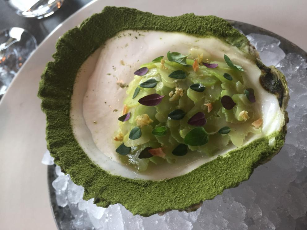 Photogallery






The traditional welcome at Noma: the chefs from the service kitchen greet the guests. In the middle, Italian Riccardo Canella, who will help us describing the last menu in detail (photo gallery by Luca Iaccarino and Gabriele Zanatta)









Warm broth of cloudberries. It’s the last welcome dish at Noma. It’s cold outside but as soon as you sit inside, you get warm thanks to this hot broth made with cloudberries enriched with rhubarb root oil. You dip a bouquet of hay, lemon thyme and mountain pine. Corroborating









Riccardo Canella brings a preview of what will follow









It’s a dish with seafood, including a huge (and alive) king crab, sea urchins and oysters









Apple of the season









Apple of the season. Once you open the shell, many small apple parisienne appear in a juice made with centrifuged, clarified apple scraps, seasoned with verbena and thyme. There’s also a purée of apples fermented in broth. The dish is finished with oxalis flowers, tagete and oil of blackcurrant wood, made by beating the blackcurrant branches with a hammer, so as to extract their essential oils. A very pleasant dish despite its complex idea.

"The first time I saw it ", added Canella, "I was struck because it reminded me of the stuffed apples they used to make at restaurant Bulesca in Selvazzano, Padua, in the early Eighties. Except in that case it was filled with rolls made with granny smith apple and prosciutto from Montagnana" 









Fresh sliced scallop. It’s a scallop taken from the fish tank and shelled a few moments before serving it. It is then sliced, brushed with a reduction of vegetable whipped butter with cucumber centrifuge juice, then reduced, and piso broth (that is to say miso with dehydrated peas).

The technique is the same used for the broth ice-clarification made famous in the Nineties by Heston Blumenthal at Fat Duck: you freeze the broth then hang a table cloth so as to obtain the “pure” part of the liquid. A trick that adds the same satisfying sensation of a meat jus to a vegetable broth. The scallop is finally dipped into a classic mussel broth. An incredible mouthful of seafood and umami









A Winter Platter. Hidden among the leaves, are four edible tastings









He sums up in just one dish 4 snacks that he might would have served separately a few years back. A fun and tasty idea. In detail:

At 6 o’clock: Pear pressed in fermented red gooseberry with fully ripe common sea buckthorn. It’s a rather tart ensemble made sweeter by piso (again miso made with dried peas) seasoned with coriander seeds (supplied by Redzepi’s historic supplier Soren Wiuff). The external thinner leaf is a peel made with chicken broth and beech leaves preserved in vinegar.

10 o'clock: crispy black currant leaf-shaped sandwich, seasoned with yogurt, kombucha, elderberry flowers and red oxalis 

12 o'clock: malt branch with nasturtium leaves, creme fraiche, salt aromatised with pine and ants

4 o'clock: black garlic leaf with salt aromatised with kelp, a Japanese seaweed 









A detail of the malt branch, with well visible ants. At Noma, the study of the aromatic contribution given by formic acid to dishes continues. And even the service acquires elegance: in the past you might have seen ants floating in a few dishes. This is no longer the case









A Tupperware from the "ant library", on the first floor at Strangade









Radish pie. It’s an emblem of the latest menus at Noma. It’s been in the menu for almost a year. In the crunchy disc on the bottom there’s kelp seaweed and a vegetable reduction made with coriander pesto. The radish roses (22, no more, no less) were pressed in beetroot juice. Another formidable tasting









Interns roll the radish roses together, on the top floor at Noma. Loud music and teamwork help making the job less alienating









Natural fermented bread of Øland wheat and hulless barley.  Øland wheat is Danish, with 83% hydration. “Nerd” bread maker Rasmus Kristensen is obsessed with it: even though it could last a week, he bakes it fresh every day for the two services (see the interview on Vice). It has a crispy yet soft crust, and it’s a great progress compared to the early bread making at the restaurant.

The salted butter is instead Norwegian Røros, according to some “the best butter in the world”. One of the most extraordinary pairings ever tasted. We asked for an encore






