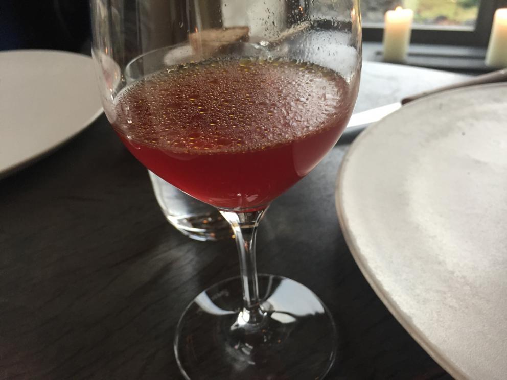 Photogallery






The traditional welcome at Noma: the chefs from the service kitchen greet the guests. In the middle, Italian Riccardo Canella, who will help us describing the last menu in detail (photo gallery by Luca Iaccarino and Gabriele Zanatta)









Warm broth of cloudberries. It’s the last welcome dish at Noma. It’s cold outside but as soon as you sit inside, you get warm thanks to this hot broth made with cloudberries enriched with rhubarb root oil. You dip a bouquet of hay, lemon thyme and mountain pine. Corroborating









Riccardo Canella brings a preview of what will follow









It’s a dish with seafood, including a huge (and alive) king crab, sea urchins and oysters









Apple of the season









Apple of the season. Once you open the shell, many small apple parisienne appear in a juice made with centrifuged, clarified apple scraps, seasoned with verbena and thyme. There’s also a purée of apples fermented in broth. The dish is finished with oxalis flowers, tagete and oil of blackcurrant wood, made by beating the blackcurrant branches with a hammer, so as to extract their essential oils. A very pleasant dish despite its complex idea.

"The first time I saw it ", added Canella, "I was struck because it reminded me of the stuffed apples they used to make at restaurant Bulesca in Selvazzano, Padua, in the early Eighties. Except in that case it was filled with rolls made with granny smith apple and prosciutto from Montagnana" 









Fresh sliced scallop. It’s a scallop taken from the fish tank and shelled a few moments before serving it. It is then sliced, brushed with a reduction of vegetable whipped butter with cucumber centrifuge juice, then reduced, and piso broth (that is to say miso with dehydrated peas).

The technique is the same used for the broth ice-clarification made famous in the Nineties by Heston Blumenthal at Fat Duck: you freeze the broth then hang a table cloth so as to obtain the “pure” part of the liquid. A trick that adds the same satisfying sensation of a meat jus to a vegetable broth. The scallop is finally dipped into a classic mussel broth. An incredible mouthful of seafood and umami









A Winter Platter. Hidden among the leaves, are four edible tastings









He sums up in just one dish 4 snacks that he might would have served separately a few years back. A fun and tasty idea. In detail:

At 6 o’clock: Pear pressed in fermented red gooseberry with fully ripe common sea buckthorn. It’s a rather tart ensemble made sweeter by piso (again miso made with dried peas) seasoned with coriander seeds (supplied by Redzepi’s historic supplier Soren Wiuff). The external thinner leaf is a peel made with chicken broth and beech leaves preserved in vinegar.

10 o'clock: crispy black currant leaf-shaped sandwich, seasoned with yogurt, kombucha, elderberry flowers and red oxalis 

12 o'clock: malt branch with nasturtium leaves, creme fraiche, salt aromatised with pine and ants

4 o'clock: black garlic leaf with salt aromatised with kelp, a Japanese seaweed 









A detail of the malt branch, with well visible ants. At Noma, the study of the aromatic contribution given by formic acid to dishes continues. And even the service acquires elegance: in the past you might have seen ants floating in a few dishes. This is no longer the case









A Tupperware from the "ant library", on the first floor at Strangade









Radish pie. It’s an emblem of the latest menus at Noma. It’s been in the menu for almost a year. In the crunchy disc on the bottom there’s kelp seaweed and a vegetable reduction made with coriander pesto. The radish roses (22, no more, no less) were pressed in beetroot juice. Another formidable tasting









Interns roll the radish roses together, on the top floor at Noma. Loud music and teamwork help making the job less alienating









Natural fermented bread of Øland wheat and hulless barley.  Øland wheat is Danish, with 83% hydration. “Nerd” bread maker Rasmus Kristensen is obsessed with it: even though it could last a week, he bakes it fresh every day for the two services (see the interview on Vice). It has a crispy yet soft crust, and it’s a great progress compared to the early bread making at the restaurant.

The salted butter is instead Norwegian Røros, according to some “the best butter in the world”. One of the most extraordinary pairings ever tasted. We asked for an encore









Cooked oyster and broccoli stems. The oyster is blanched for two minutes and placed on a shell with the edges powdered with salicornia. Between the broccoli and the oyster there are some diced stalks of sorrel. There’s a reduction with kelp seaweed, whisked with butter, thyme and “capers” made with white currants [they’re not real capers but the currants are preserved for a year in 2% salt, like capers). The sauce for the oyster is made with white gooseberries. An artwork, but less convincing than the other tastings









Sea urchin and cabbage. It’s a cabbage leaf pressed with hazelnut oil, filled with sea urchin roe and seasoned with pine vinegar, water from fermented porcini and pickled chanterelle mushrooms. On top, there’s parsley pesto and salt aromatised with pine. It’s a dish that changes greatly according to the season: compared to September, the leaves are now smaller and woodier. Two extraordinary mouthfuls, the result of a rather simple intuition









Sea urchin and cabbage, a detail. Northern sea urchins are creamier than Italian ones. A blast









Langoustine, onion and lavender. The langoustine is the precious one from the Far Oer Islands. The onion is Danish and grilled, steamed in a vacuum bag with Koji oil (blended rapeseed oil with fermented oil) and then grilled again, only slightly, so as to get a golden nuance. The langoustine is instead cooked in its shell, seared in butter at 60°C for 2 minutes, then peeled, cut and served. Rose oil, vinegar made with lovage sprouts and dried lavender complete the picture. The dish is focused on the sweetness given by the onion, which has a similar texture to the langoustine. Very nice









Butternut squash, barley and caviar. The butternut squash is confit in oil aromatised with seaweeds later roasted and placed on top. It is completed with beechnuts, a sauce made with fermented barley and butter and a handful of Finnish caviar. A sweet interlude









Claws and heads of a langoustine from the Far Oer Islands, cut in two. The heads of the langoustine are braised with a paste made with the entrails of the langoustine and a reduction of yeast and thyme and lemon on top. A very pleasing neo-primitive tasting with a strong dose of umami









Steamed king crab and egg yolk sauce. A new take on a classic Japanese dish, learnt in Tokyo and applied in Australia to a snow crab. Global nomadism made Redzepi’s cuisine rounder, less extreme than in the past









In this case, the king crab is steamed and seasoned with smoked salt. The sauce is made with egg yolks marinated in beef garum, a trick that gives a significant sour component to the recipe. Finally, there’s a seasoning made of butter and piso. An interesting depth









Charred greens with a scallop paste. There are plenty of seasonal herbs and vegetables, in this case cabbage, black cabbage, sage, verbena, nettle and the first sprouts of wild garlic. The caramel is made with a purée of fresh scallop, rolled out for 48 hours on a silpat. Once dehydrated, it becomes dark orange. They then blend it, powder it, mix it with bees’ wax and rapeseed oil. Finally they cover the caramel with horseradish juice. Another interlocutory tasting, fun and very much appreciated thanks to the crispiness and the bitter-sweet herbs. Trivia fact: the dish is served with a steak knife. That is to say: herb is the new meat









Roasted Bone Marrow. It’s not the first time they serve grilled bone marrow at Noma, legitimised in fine dining by English Fergus Henderson. What’s new is the way in which they have been serving it in Copenhagen for around one month now: the bone marrow is surrounded by many small plates and garnishes, so guests can enrich it to their liking. A similar idea to what Paolo Lopriore does every day at Portico in Appiano Gentile

 














Among the garnishes that can enrich the bone marrow are pickles, wild mushrooms with beef garum paste, wild herb paste, fresh garlic, leek flower sprouts preserved in salt and salt aromatised with roasted seaweed









Other complements for the bone marrow: to the right, chicken "skin" made with dehydrated jus ("the skin is the best part of a chicken", once Redzepi demonstrated in Belgium) and next to it a vegetal reduction with black garlic









The slices of truffle from Gotland (Sweden) paired with bone marrow are not as strong as those we’re used to. This is why at Noma they add oil aromatised with porcini, aged Danish whiskey and a garum made with Dryad's seddle mushrooms, with a delicate pineapple scent









A dessert of potatoes and plums. Another great emblem of the most recent offer at Noma. Three creams stand out on a sauce of juice and plum aquavit: right to left, a compote of plums (dehydrated in the oven so as to concentrate their aroma), a purée of sweet Danish potatoes and a cream seasoned with plum nuts, which surprisingly recall almonds









Black currant wood ice cream and roasted konini. Also known as "No-Magnum", Noma’s Magnum, unites konini [an ancient Swedish wheat] roasted like coffee, oxalis, a reduction of quince syrup and a few leaves of verbena. Every day the guys sharpen some 200 branches of black currants









Moss cooked in white chocolate. It’s the sweet version of the famous Moss and Cep, a “savoury” dish from the early days. It’s fried musk covered in white chocolate. Next to it, a disc covered in chocolate with powdered liquorice on top (even Redzepi had to surrender to the exotic deliciousness of cocoa)









A note on the beverages: after a welcome glass of champagne (André Belfort Brut 2008, curiously the same tasted the previous night at Christian Puglisi’s Relae), we chose to continue with the juice menu, 6 glasses of variably good organic juices for 700 Danish crowns each (around 95 euros)









There’s a person in the staff at Noma who’s dedicated entirely to the juice menu. The first juice served was apple/pine. Each glass stays on the table for around 3 courses on average. Food and juice pairings are partly designed, partly casual






