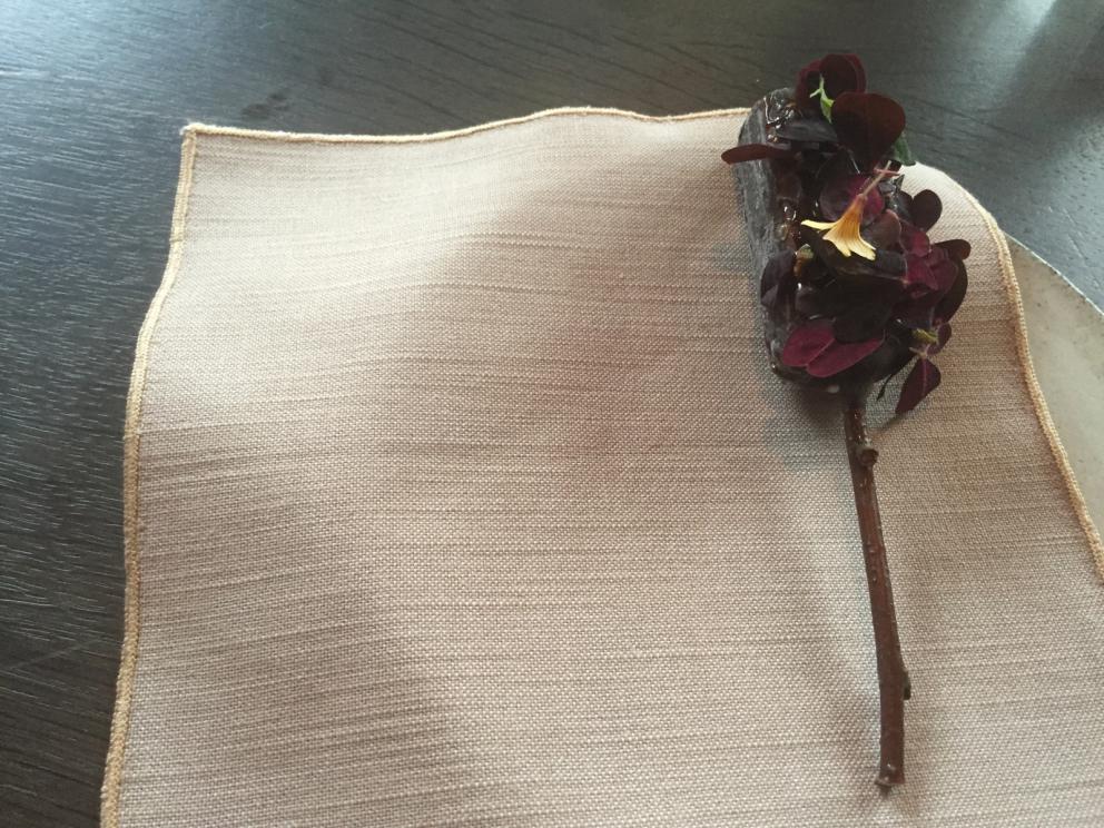 Photogallery






The traditional welcome at Noma: the chefs from the service kitchen greet the guests. In the middle, Italian Riccardo Canella, who will help us describing the last menu in detail (photo gallery by Luca Iaccarino and Gabriele Zanatta)









Warm broth of cloudberries. It’s the last welcome dish at Noma. It’s cold outside but as soon as you sit inside, you get warm thanks to this hot broth made with cloudberries enriched with rhubarb root oil. You dip a bouquet of hay, lemon thyme and mountain pine. Corroborating









Riccardo Canella brings a preview of what will follow









It’s a dish with seafood, including a huge (and alive) king crab, sea urchins and oysters









Apple of the season









Apple of the season. Once you open the shell, many small apple parisienne appear in a juice made with centrifuged, clarified apple scraps, seasoned with verbena and thyme. There’s also a purée of apples fermented in broth. The dish is finished with oxalis flowers, tagete and oil of blackcurrant wood, made by beating the blackcurrant branches with a hammer, so as to extract their essential oils. A very pleasant dish despite its complex idea.

"The first time I saw it ", added Canella, "I was struck because it reminded me of the stuffed apples they used to make at restaurant Bulesca in Selvazzano, Padua, in the early Eighties. Except in that case it was filled with rolls made with granny smith apple and prosciutto from Montagnana" 









Fresh sliced scallop. It’s a scallop taken from the fish tank and shelled a few moments before serving it. It is then sliced, brushed with a reduction of vegetable whipped butter with cucumber centrifuge juice, then reduced, and piso broth (that is to say miso with dehydrated peas).

The technique is the same used for the broth ice-clarification made famous in the Nineties by Heston Blumenthal at Fat Duck: you freeze the broth then hang a table cloth so as to obtain the “pure” part of the liquid. A trick that adds the same satisfying sensation of a meat jus to a vegetable broth. The scallop is finally dipped into a classic mussel broth. An incredible mouthful of seafood and umami









A Winter Platter. Hidden among the leaves, are four edible tastings









He sums up in just one dish 4 snacks that he might would have served separately a few years back. A fun and tasty idea. In detail:

At 6 o’clock: Pear pressed in fermented red gooseberry with fully ripe common sea buckthorn. It’s a rather tart ensemble made sweeter by piso (again miso made with dried peas) seasoned with coriander seeds (supplied by Redzepi’s historic supplier Soren Wiuff). The external thinner leaf is a peel made with chicken broth and beech leaves preserved in vinegar.

10 o'clock: crispy black currant leaf-shaped sandwich, seasoned with yogurt, kombucha, elderberry flowers and red oxalis 

12 o'clock: malt branch with nasturtium leaves, creme fraiche, salt aromatised with pine and ants

4 o'clock: black garlic leaf with salt aromatised with kelp, a Japanese seaweed 









A detail of the malt branch, with well visible ants. At Noma, the study of the aromatic contribution given by formic acid to dishes continues. And even the service acquires elegance: in the past you might have seen ants floating in a few dishes. This is no longer the case









A Tupperware from the "ant library", on the first floor at Strangade









Radish pie. It’s an emblem of the latest menus at Noma. It’s been in the menu for almost a year. In the crunchy disc on the bottom there’s kelp seaweed and a vegetable reduction made with coriander pesto. The radish roses (22, no more, no less) were pressed in beetroot juice. Another formidable tasting









Interns roll the radish roses together, on the top floor at Noma. Loud music and teamwork help making the job less alienating









Natural fermented bread of Øland wheat and hulless barley.  Øland wheat is Danish, with 83% hydration. “Nerd” bread maker Rasmus Kristensen is obsessed with it: even though it could last a week, he bakes it fresh every day for the two services (see the interview on Vice). It has a crispy yet soft crust, and it’s a great progress compared to the early bread making at the restaurant.

The salted butter is instead Norwegian Røros, according to some “the best butter in the world”. One of the most extraordinary pairings ever tasted. We asked for an encore









Cooked oyster and broccoli stems. The oyster is blanched for two minutes and placed on a shell with the edges powdered with salicornia. Between the broccoli and the oyster there are some diced stalks of sorrel. There’s a reduction with kelp seaweed, whisked with butter, thyme and “capers” made with white currants [they’re not real capers but the currants are preserved for a year in 2% salt, like capers). The sauce for the oyster is made with white gooseberries. An artwork, but less convincing than the other tastings









Sea urchin and cabbage. It’s a cabbage leaf pressed with hazelnut oil, filled with sea urchin roe and seasoned with pine vinegar, water from fermented porcini and pickled chanterelle mushrooms. On top, there’s parsley pesto and salt aromatised with pine. It’s a dish that changes greatly according to the season: compared to September, the leaves are now smaller and woodier. Two extraordinary mouthfuls, the result of a rather simple intuition









Sea urchin and cabbage, a detail. Northern sea urchins are creamier than Italian ones. A blast









Langoustine, onion and lavender. The langoustine is the precious one from the Far Oer Islands. The onion is Danish and grilled, steamed in a vacuum bag with Koji oil (blended rapeseed oil with fermented oil) and then grilled again, only slightly, so as to get a golden nuance. The langoustine is instead cooked in its shell, seared in butter at 60°C for 2 minutes, then peeled, cut and served. Rose oil, vinegar made with lovage sprouts and dried lavender complete the picture. The dish is focused on the sweetness given by the onion, which has a similar texture to the langoustine. Very nice









Butternut squash, barley and caviar. The butternut squash is confit in oil aromatised with seaweeds later roasted and placed on top. It is completed with beechnuts, a sauce made with fermented barley and butter and a handful of Finnish caviar. A sweet interlude









Claws and heads of a langoustine from the Far Oer Islands, cut in two. The heads of the langoustine are braised with a paste made with the entrails of the langoustine and a reduction of yeast and thyme and lemon on top. A very pleasing neo-primitive tasting with a strong dose of umami









Steamed king crab and egg yolk sauce. A new take on a classic Japanese dish, learnt in Tokyo and applied in Australia to a snow crab. Global nomadism made Redzepi’s cuisine rounder, less extreme than in the past









In this case, the king crab is steamed and seasoned with smoked salt. The sauce is made with egg yolks marinated in beef garum, a trick that gives a significant sour component to the recipe. Finally, there’s a seasoning made of butter and piso. An interesting depth









Charred greens with a scallop paste. There are plenty of seasonal herbs and vegetables, in this case cabbage, black cabbage, sage, verbena, nettle and the first sprouts of wild garlic. The caramel is made with a purée of fresh scallop, rolled out for 48 hours on a silpat. Once dehydrated, it becomes dark orange. They then blend it, powder it, mix it with bees’ wax and rapeseed oil. Finally they cover the caramel with horseradish juice. Another interlocutory tasting, fun and very much appreciated thanks to the crispiness and the bitter-sweet herbs. Trivia fact: the dish is served with a steak knife. That is to say: herb is the new meat









Roasted Bone Marrow. It’s not the first time they serve grilled bone marrow at Noma, legitimised in fine dining by English Fergus Henderson. What’s new is the way in which they have been serving it in Copenhagen for around one month now: the bone marrow is surrounded by many small plates and garnishes, so guests can enrich it to their liking. A similar idea to what Paolo Lopriore does every day at Portico in Appiano Gentile

 














Among the garnishes that can enrich the bone marrow are pickles, wild mushrooms with beef garum paste, wild herb paste, fresh garlic, leek flower sprouts preserved in salt and salt aromatised with roasted seaweed









Other complements for the bone marrow: to the right, chicken "skin" made with dehydrated jus ("the skin is the best part of a chicken", once Redzepi demonstrated in Belgium) and next to it a vegetal reduction with black garlic









The slices of truffle from Gotland (Sweden) paired with bone marrow are not as strong as those we’re used to. This is why at Noma they add oil aromatised with porcini, aged Danish whiskey and a garum made with Dryad's seddle mushrooms, with a delicate pineapple scent









A dessert of potatoes and plums. Another great emblem of the most recent offer at Noma. Three creams stand out on a sauce of juice and plum aquavit: right to left, a compote of plums (dehydrated in the oven so as to concentrate their aroma), a purée of sweet Danish potatoes and a cream seasoned with plum nuts, which surprisingly recall almonds






