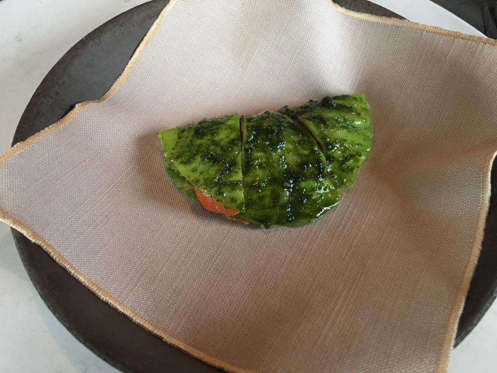 Photogallery






The traditional welcome at Noma: the chefs from the service kitchen greet the guests. In the middle, Italian Riccardo Canella, who will help us describing the last menu in detail (photo gallery by Luca Iaccarino and Gabriele Zanatta)









Warm broth of cloudberries. It’s the last welcome dish at Noma. It’s cold outside but as soon as you sit inside, you get warm thanks to this hot broth made with cloudberries enriched with rhubarb root oil. You dip a bouquet of hay, lemon thyme and mountain pine. Corroborating









Riccardo Canella brings a preview of what will follow









It’s a dish with seafood, including a huge (and alive) king crab, sea urchins and oysters









Apple of the season









Apple of the season. Once you open the shell, many small apple parisienne appear in a juice made with centrifuged, clarified apple scraps, seasoned with verbena and thyme. There’s also a purée of apples fermented in broth. The dish is finished with oxalis flowers, tagete and oil of blackcurrant wood, made by beating the blackcurrant branches with a hammer, so as to extract their essential oils. A very pleasant dish despite its complex idea.

"The first time I saw it ", added Canella, "I was struck because it reminded me of the stuffed apples they used to make at restaurant Bulesca in Selvazzano, Padua, in the early Eighties. Except in that case it was filled with rolls made with granny smith apple and prosciutto from Montagnana" 









Fresh sliced scallop. It’s a scallop taken from the fish tank and shelled a few moments before serving it. It is then sliced, brushed with a reduction of vegetable whipped butter with cucumber centrifuge juice, then reduced, and piso broth (that is to say miso with dehydrated peas).

The technique is the same used for the broth ice-clarification made famous in the Nineties by Heston Blumenthal at Fat Duck: you freeze the broth then hang a table cloth so as to obtain the “pure” part of the liquid. A trick that adds the same satisfying sensation of a meat jus to a vegetable broth. The scallop is finally dipped into a classic mussel broth. An incredible mouthful of seafood and umami









A Winter Platter. Hidden among the leaves, are four edible tastings









He sums up in just one dish 4 snacks that he might would have served separately a few years back. A fun and tasty idea. In detail:

At 6 o’clock: Pear pressed in fermented red gooseberry with fully ripe common sea buckthorn. It’s a rather tart ensemble made sweeter by piso (again miso made with dried peas) seasoned with coriander seeds (supplied by Redzepi’s historic supplier Soren Wiuff). The external thinner leaf is a peel made with chicken broth and beech leaves preserved in vinegar.

10 o'clock: crispy black currant leaf-shaped sandwich, seasoned with yogurt, kombucha, elderberry flowers and red oxalis 

12 o'clock: malt branch with nasturtium leaves, creme fraiche, salt aromatised with pine and ants

4 o'clock: black garlic leaf with salt aromatised with kelp, a Japanese seaweed 









A detail of the malt branch, with well visible ants. At Noma, the study of the aromatic contribution given by formic acid to dishes continues. And even the service acquires elegance: in the past you might have seen ants floating in a few dishes. This is no longer the case









A Tupperware from the "ant library", on the first floor at Strangade









Radish pie. It’s an emblem of the latest menus at Noma. It’s been in the menu for almost a year. In the crunchy disc on the bottom there’s kelp seaweed and a vegetable reduction made with coriander pesto. The radish roses (22, no more, no less) were pressed in beetroot juice. Another formidable tasting









Interns roll the radish roses together, on the top floor at Noma. Loud music and teamwork help making the job less alienating









Natural fermented bread of Øland wheat and hulless barley.  Øland wheat is Danish, with 83% hydration. “Nerd” bread maker Rasmus Kristensen is obsessed with it: even though it could last a week, he bakes it fresh every day for the two services (see the interview on Vice). It has a crispy yet soft crust, and it’s a great progress compared to the early bread making at the restaurant.

The salted butter is instead Norwegian Røros, according to some “the best butter in the world”. One of the most extraordinary pairings ever tasted. We asked for an encore









Cooked oyster and broccoli stems. The oyster is blanched for two minutes and placed on a shell with the edges powdered with salicornia. Between the broccoli and the oyster there are some diced stalks of sorrel. There’s a reduction with kelp seaweed, whisked with butter, thyme and “capers” made with white currants [they’re not real capers but the currants are preserved for a year in 2% salt, like capers). The sauce for the oyster is made with white gooseberries. An artwork, but less convincing than the other tastings






